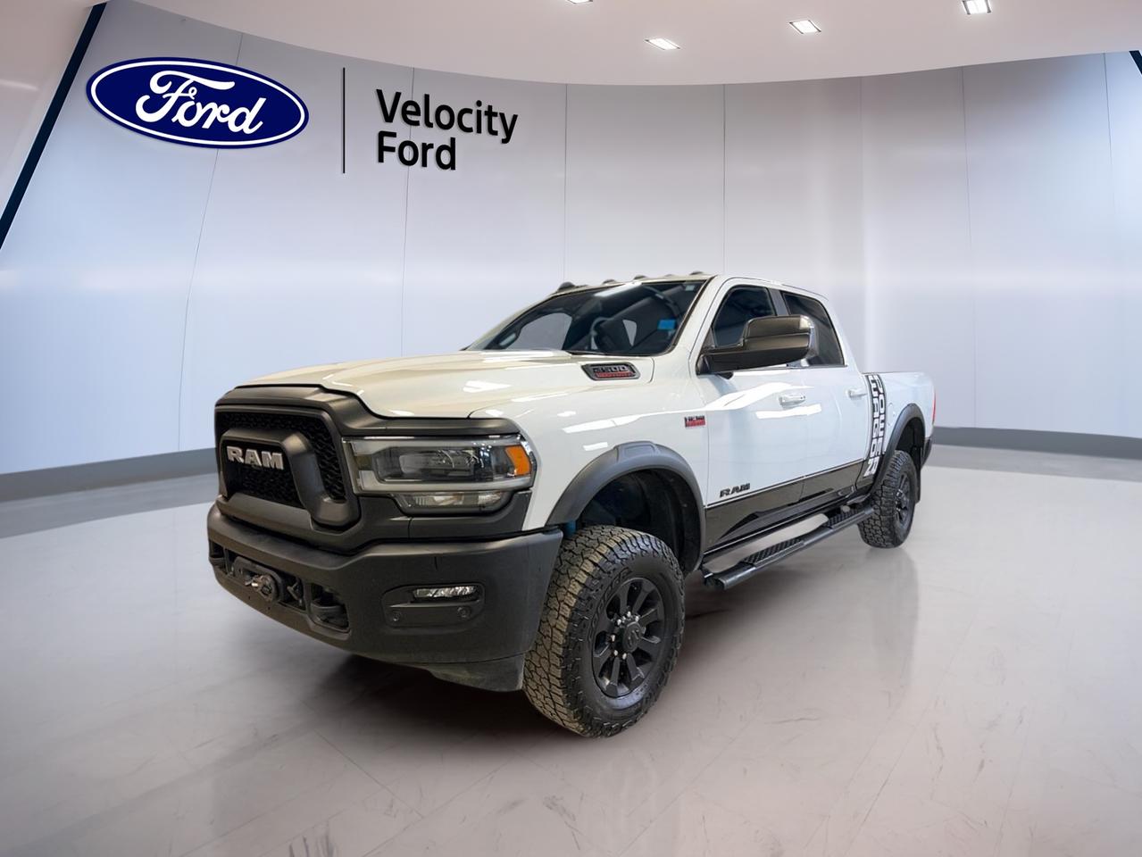 Experience uncompromising capability with the 2020 RAM 2500 Power Wagon Crew Cab, available now at Velocity Ford in Moose Jaw. This robust truck, finished in a clean white exterior with a black interior, is engineered for both heavy-duty work and off-road adventure. With 193,737 km on the odometer, it stands ready to deliver reliable performance for years to come. The 6.4-litre gas engine, paired with an 8-speed automatic transmission, ensures seamless power delivery whether youre towing, hauling, or exploring rugged terrain.

TRUCK FEATURES
»» Towing capacity up to 4,771 kg
»» Four-wheel drive for challenging conditions
»» Rear tow hook for added utility
»» Off-road tires for enhanced traction

ADVANCED SAFETY FEATURES
»» Anti-lock braking system (ABS) for controlled stops
»» Stability control for improved handling
»» Multiple airbags including side impact and head side
»» Child safety locks for added protection

PERFORMANCE AND EFFICIENCY
»» 6.4-litre V8 gas engine for strong output
»» Limited slip differential for optimal traction
»» Automatic transmission with 8-speed efficiency
»» Four-wheel drive for versatile performance

COMFORT AND CONVENIENCE
»» Power steering for effortless control
»» Front air conditioning for cabin comfort
»» Adjustable steering wheel for personalized fit
»» Drivers seat lumbar support for long drives

TECHNOLOGY AND CONNECTIVITY
»» Bluetooth integration for hands-free calls
»» Satellite radio for entertainment on the go
»» Steering wheel audio controls for convenience
»» Backup camera for safer reversing

CARGO SPACE
»» Rear trunk access for easy loading
»» Spacious Crew Cab for passengers and gear
»» Retractable mirrors for tight spaces
»» Spare tire included for peace of mind

AWARDS & RECOGNITIONS

WHAT OTHER OWNERS LIKE
»» Powerful towing and off-road capabilities
»» Comfortable ride for a heavy-duty truck
»» User-friendly technology and controls
»» Dependable performance in all conditions


This 2020 RAM 2500 Power Wagon Crew Cabs VIN is: 3C6TR5EJ0LG274341.