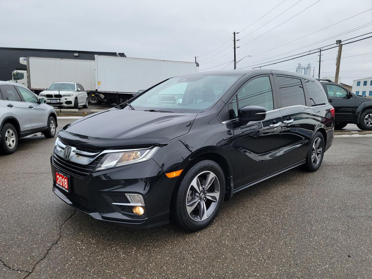 <h3 data-start=143 data-end=184>FULLY LOADED 2018 Honda Odyssey EX-L w/ Navigation</h3><p data-start=186 data-end=476>The 2018 Honda Odyssey EX-L with Navigation delivers the ideal balance of space, comfort, safety, and technology. Known for its smooth ride and family-friendly design, this Odyssey is a reliable and versatile minivan that works just as well for daily driving as it does for long road trips.</p><h4 data-start=478 data-end=507>Performance & Drivetrain</h4><ul data-start=508 data-end=648><li data-start=508 data-end=533><p data-start=510 data-end=533>3.5L i-VTEC V6 engine</p></li><li data-start=534 data-end=568><p data-start=536 data-end=568>9-speed automatic transmission</p></li><li data-start=569 data-end=590><p data-start=571 data-end=590>Front-wheel drive</p></li><li data-start=591 data-end=628><p data-start=593 data-end=628>Eco Assist fuel efficiency system</p></li><li data-start=629 data-end=648><p data-start=631 data-end=648>Paddle shifters</p></li></ul><h4 data-start=650 data-end=697>Safety & Driver Assistance (Honda Sensing)</h4><ul data-start=698 data-end=1133><li data-start=698 data-end=737><p data-start=700 data-end=737>Collision Mitigation Braking System</p></li><li data-start=738 data-end=767><p data-start=740 data-end=767>Forward Collision Warning</p></li><li data-start=768 data-end=798><p data-start=770 data-end=798>Lane Keeping Assist System</p></li><li data-start=799 data-end=825><p data-start=801 data-end=825>Lane Departure Warning</p></li><li data-start=826 data-end=855><p data-start=828 data-end=855>Road Departure Mitigation</p></li><li data-start=856 data-end=883><p data-start=858 data-end=883>Adaptive Cruise Control</p></li><li data-start=884 data-end=917><p data-start=886 data-end=917>Blind Spot Information System</p></li><li data-start=918 data-end=948><p data-start=920 data-end=948>Rear Cross Traffic Monitor</p></li><li data-start=949 data-end=980><p data-start=951 data-end=980>Multi-angle rearview camera</p></li><li data-start=981 data-end=1031><p data-start=983 data-end=1031>Vehicle Stability Assist with traction control</p></li><li data-start=1032 data-end=1060><p data-start=1034 data-end=1060>Anti-lock braking system</p></li><li data-start=1061 data-end=1096><p data-start=1063 data-end=1096>Tire Pressure Monitoring System</p></li><li data-start=1097 data-end=1133><p data-start=1099 data-end=1133>Front, side, and curtain airbags</p></li></ul><h4 data-start=1135 data-end=1163>Technology & Navigation</h4><ul data-start=1164 data-end=1437><li data-start=1164 data-end=1199><p data-start=1166 data-end=1199>Factory Honda Navigation System</p></li><li data-start=1200 data-end=1230><p data-start=1202 data-end=1230>8-inch touchscreen display</p></li><li data-start=1231 data-end=1265><p data-start=1233 data-end=1265>Apple CarPlay and Android Auto</p></li><li data-start=1266 data-end=1318><p data-start=1268 data-end=1318>Bluetooth hands-free calling and audio streaming</p></li><li data-start=1319 data-end=1340><p data-start=1321 data-end=1340>Voice recognition</p></li><li data-start=1341 data-end=1369><p data-start=1343 data-end=1369>SiriusXM satellite radio</p></li><li data-start=1370 data-end=1393><p data-start=1372 data-end=1393>USB and HDMI inputs</p></li><li data-start=1394 data-end=1437><p data-start=1396 data-end=1437>Steering wheel audio and phone controls</p></li></ul><h4 data-start=1439 data-end=1462>Interior & Comfort</h4><ul data-start=1463 data-end=1747><li data-start=1463 data-end=1490><p data-start=1465 data-end=1490>Leather-trimmed seating</p></li><li data-start=1491 data-end=1544><p data-start=1493 data-end=1544>Power adjustable driver and front passenger seats</p></li><li data-start=1545 data-end=1567><p data-start=1547 data-end=1567>Heated front seats</p></li><li data-start=1568 data-end=1606><p data-start=1570 data-end=1606>Tri-zone automatic climate control</p></li><li data-start=1607 data-end=1625><p data-start=1609 data-end=1625>Power moonroof</p></li><li data-start=1626 data-end=1664><p data-start=1628 data-end=1664>Push-button start with smart entry</p></li><li data-start=1665 data-end=1699><p data-start=1667 data-end=1699>Leather-wrapped steering wheel</p></li><li data-start=1700 data-end=1728><p data-start=1702 data-end=1728>Power sliding side doors</p></li><li data-start=1729 data-end=1747><p data-start=1731 data-end=1747>Power tailgate</p></li></ul><h4 data-start=1749 data-end=1775>Seating & Versatility</h4><ul data-start=1776 data-end=1959><li data-start=1776 data-end=1810><p data-start=1778 data-end=1810>Seating for up to 8 passengers</p></li><li data-start=1811 data-end=1872><p data-start=1813 data-end=1872>Magic Slide second-row seats (removable and configurable)</p></li><li data-start=1873 data-end=1916><p data-start=1875 data-end=1916>60/40 split fold-flat third-row seating</p></li><li data-start=1917 data-end=1959><p data-start=1919 data-end=1959>Large cargo area with flexible layouts</p></li></ul><h4 data-start=1961 data-end=1986>Convenience Features</h4><ul data-start=1987 data-end=2103><li data-start=1987 data-end=2011><p data-start=1989 data-end=2011>Remote keyless entry</p></li><li data-start=2012 data-end=2030><p data-start=2014 data-end=2030>Cruise control</p></li><li data-start=2031 data-end=2053><p data-start=2033 data-end=2053>Rear privacy glass</p></li><li data-start=2054 data-end=2103><p data-start=2056 data-end=2103>Multiple storage compartments and cup holders</p></li></ul><p data-start=2105 data-end=2202>A well-equipped Odyssey that checks all the boxes for comfort, safety, and everyday practicality.</p><p><strong>Additional Certification Cost</strong>: The full certification cost for this vehicle is <strong>$790 + HST</strong>.</p><p><strong>What&rsquo;s Included with Certification</strong>:</p><ul><li>The vehicle will be delivered with a <strong>valid safety certification</strong> and a <strong>36-day safety item warranty</strong> for your peace of mind.</li><li>A <strong>fresh oil change</strong> will be performed, and all fluids will be topped up.</li><li>The vehicle will be <strong>professionally detailed</strong>, ensuring it looks and feels like new when you pick it up.</li></ul><p>At <strong>Twin Oaks Auto</strong>, we are committed to providing a <strong>hassle-free car buying experience</strong>. From your first inquiry to driving off in your new car, our goal is to get you on the road quickly and stress-free!</p><p><strong>Financing Options Available!</strong><br>Flexible financing options are available to suit your needs. Contact us for more details.</p><p><strong>Contact Us Today</strong>:<br>📞 <strong>Call Us</strong>: 905-339-3330<br>📍 <strong>Location</strong>: 2470 Royal Windsor Drive, Oakville, Ontario, L6J 7Y2</p><p><br>(Conveniently located between Ford Drive and Winston Churchill Blvd.)</p><p><strong>More Information</strong>:<br>Visit our website at <strong><a href=http://www.twinoaksauto.com>TwinOaksAuto.com</a></strong> to view additional pictures, explore our inventory, and access CARFAX reports.</p><p>&nbsp;</p>