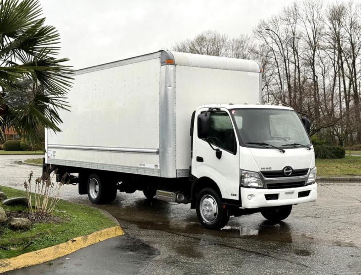 This 2018 Hino 195 cube van is powered by a 5.1L 4-cylinder diesel engine paired with an automatic transmission and rear-wheel drive, configured for medium-duty commercial delivery and transport. It features a 20-foot cargo box with inside dimensions of approximately 20 ft long, 8 ft 4 in wide, and 7 ft 8 in high, along with a power tail gate and dedicated power switch to assist with loading operations. Equipment includes cruise control, engine brake, air conditioning and heat, AM/FM radio, heated mirrors, power windows, power door locks, power mirrors, and integrated cup holders. Finished in a white exterior with grey cloth interior, the overall vehicle measures approximately 28 ft 1 in long, 8 ft 4 in wide, and 12 ft high, and is rated at a GVWR of 8,850 kg (19,500 lb), making it well suited for fleet use, logistics, and delivery applications requiring a full-length cube body with lift gate support. This item is currently OFFSITE. You must register an appointment with our office to schedule an offsite viewing. Appointments must be made a minimum of one business day in advance (and as defined by the days that Repo.com is open for business) before your appointment can be scheduled and confirmed. We may, at our own discretion, instead opt to transport smaller items to Repo.coms main yard for viewing purposes.  $39,810.00 plus $375 processing fee, $40,185.00 total payment obligation before taxes.  Listing report, warranty, contract commitment cancellation fee, financing available on approved credit (some limitations and exceptions may apply). All above specifications and information is considered to be accurate but is not guaranteed and no opinion or advice is given as to whether this item should be purchased. We do not allow test drives due to theft, fraud, acts of vandalism and undetectable impaired driving. Instead we provide the following benefits: Complimentary Warranty (with options to extend), Limited Money Back Satisfaction Guarantee on Fully Completed Contracts, Contract Commitment Cancellation, and an Open-Ended Sell-Back Option. Ask seller for details or call 604-522-REPO(7376) to confirm listing availability.