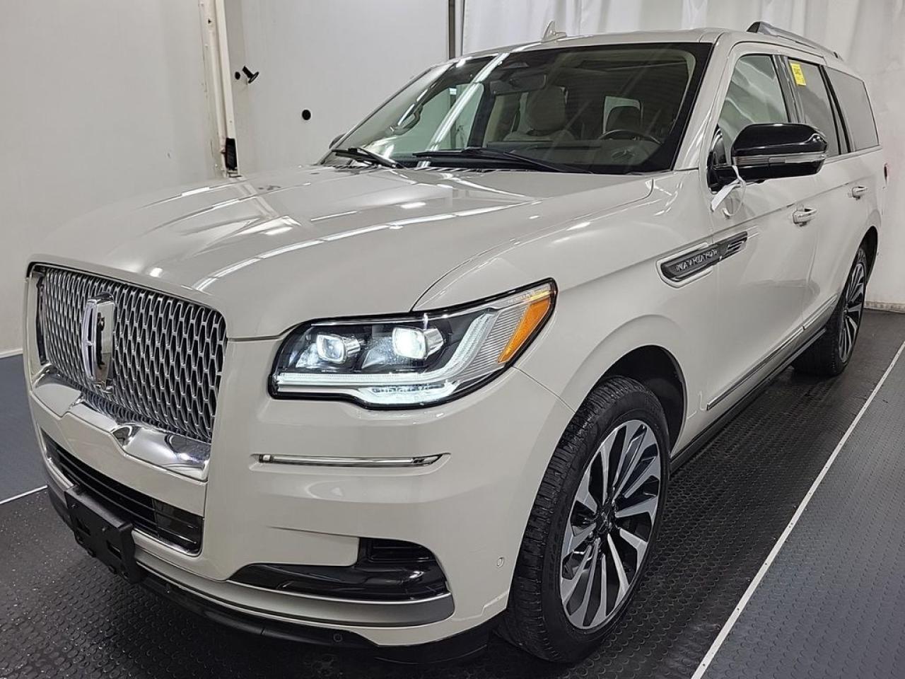 THE PRICE YOU SEE, PLUS GST. GUARANTEED!APPLE CARPLAY/ANDROID AUTO COMPATABLE! ***FORD DEMO UNIT***3.5 LITER ECOBOOST ENGINE, 10 SPEED AUTO, RESERVE TRIM(201a), 8 PASSENGER SEATING, SANDSTONE LEATHER, 2ND ROW BENCH SEAT, LINCOLN PLAY, REAR SEAT ENTERTAINMENT, HEATED/COOLED FRONT SEATS, HEATED STEERING WHEEL, LINCOLN CO-PILOT 360 2.0, LINCOLN CONNECT, ADAPTIVE CRUISE W/ STOP & GO, PANORAMIC VISTA ROOF, PHONE AS A KEY.     The 2023 Lincoln Navigator Reserve, equipped with the powerful 3.5-liter EcoBoost V6 engine, offers a commanding blend of performance, luxury, and advanced technology. The EcoBoost engine provides impressive horsepower and torque, delivering smooth acceleration and the capability to handle towing and challenging driving conditions with ease. The 201A Package enhances the vehicles interior with premium features, including upgraded leather upholstery, advanced driver-assistance systems, and state-of-the-art infotainment options, creating a refined and convenient driving experience. The Lincoln Play Rear Seat Entertainment system adds a touch of luxury for rear passengers, featuring large screens, wireless connectivity, and compatibility with various media sources, making long journeys more enjoyable. Inside, the Navigator Reserve boasts spacious, plush seating with power adjustments, climate control, and high-quality materials, emphasizing comfort and sophistication. The combination of robust performance, luxurious amenities, and innovative entertainment options makes the 2023 Lincoln Navigator Reserve a top-tier SUV designed for those who desire both power and premium comfort.Do you want to know more about this vehicle, CALL, CLICK OR COME ON IN!*AMVIC Licensed Dealer; CarFax and Full Mechanical Inspection Included.