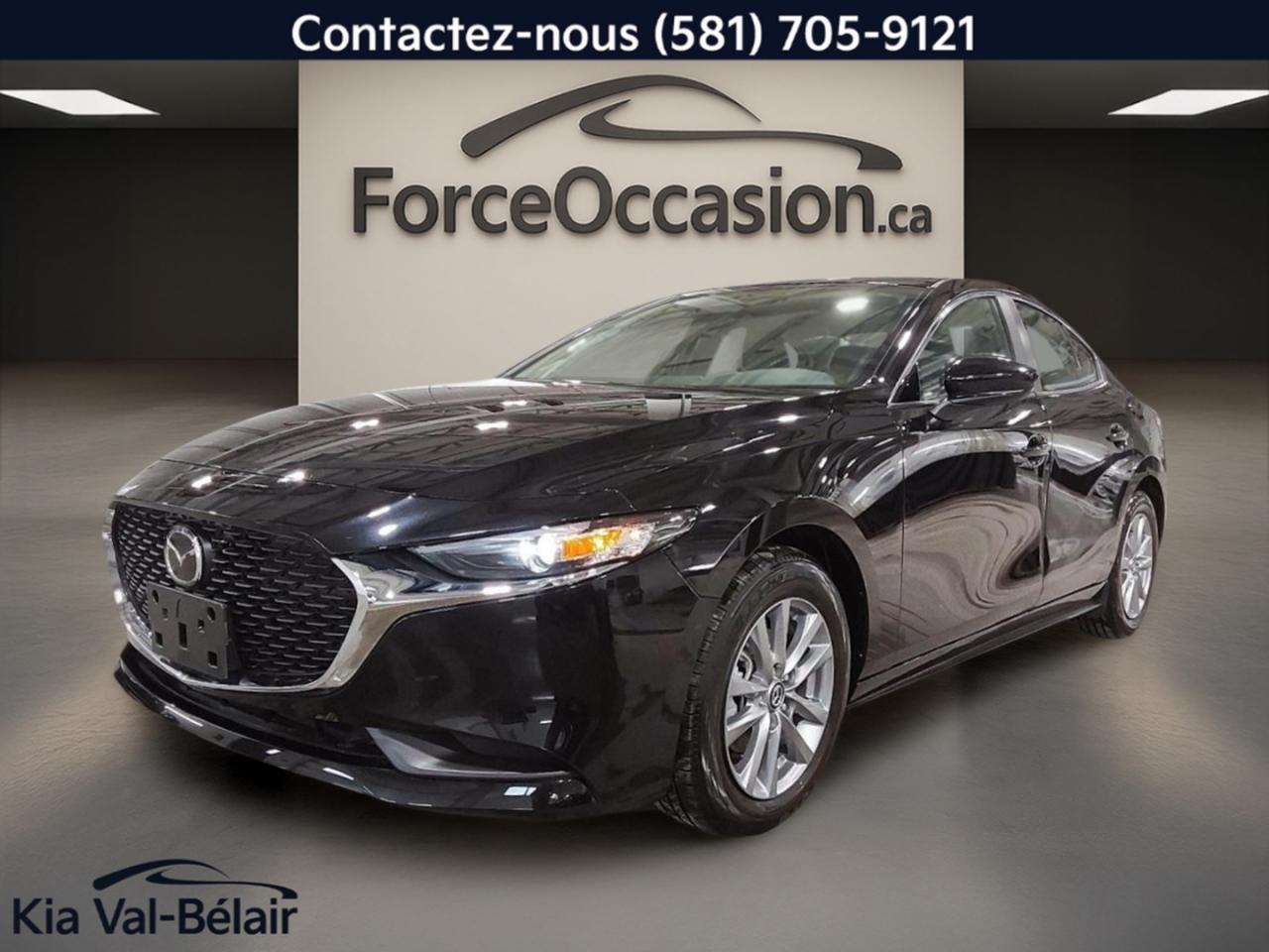 Très Propre // Inspecté en 135 points

La Mazda Mazda3 2025 GX est une berline 4 portes idéale pour Québec, avec seulement 3 503 km à lodomètre. Son moteur 2,5 L à essence ordinaire et sa transmission automatique offrent une conduite simple et rassurante au quotidien. Ce modèle noir sur noir mise aussi sur le confort, la connectivité et des aides à la conduite utiles.

CARACTÉRISTIQUES DE SÉCURITÉ AVANCÉES  
»» Surveillance des angles morts intégrée  
»» Avertissement de sortie de voie  
»» Coussins gonflables latéraux et rideaux  
»» Caméra de recul pour manoeuvres faciles  

PERFORMANCE ET EFFICACITÉ  
»» Moteur 2,5 L à essence ordinaire  
»» Transmission automatique à 6 vitesses  
»» Traction avant pour conduite prévisible  
»» Contrôle de stabilité et ABS inclus  

CONFORT  
»» Sièges avant chauffants pour lhiver  
»» Climatisation avant à deux zones  
»» Démarrage par bouton-poussoir pratique  
»» Volant réglable avec commandes audio  

TECHNOLOGIE ET CONNECTIVITÉ  
»» Apple CarPlay pour vos applications compatibles  
»» Intégration Bluetooth pour appels et musique  
»» Commandes audio directement au volant  
»» Phares automatiques pour plus de simplicité  

ESPACE DE CHARGEMENT  
»» Accès au coffre arrière pratique  
»» Coffre arrière facile à charger  
»» Pneu de secours inclus  
»» Dégivreur de vitre arrière intégré  

APPRÉCIÉ DES AUTRES PROPRIÉTAIRES  
»» Conduite stable et direction précise  
»» Confort en hiver grâce aux sièges chauffants  
»» Facilité dutilisation des commandes  
»» Bonne visibilité avec caméra de recul  

GARANTIE  
Garantie originale du manufacturier: 100000 Km  

Chez Kia Val-Bélair à Québec, cette Mazda Mazda3 2025 GX usagée se démarque par son faible kilométrage, sa présentation sobre noir sur noir et ses équipements bien choisis pour la vie de tous les jours. Avec ses rétroviseurs chauffants et électriques, ses vitres électriques et son verrouillage automatique des portes, il est prêt pour vos déplacements, peu importe la saison.

Côté conduite, le moteur 2,5 L (sans plomb) est jumelé à une transmission automatique. La traction avant, le système de freinage antiblocage (ABS) et le contrôle de stabilité contribuent à une tenue de route sécurisante, autant en ville que sur lautoroute. Pour les trajets plus longs, le régulateur de vitesse aide à garder un rythme constant.

Lhabitacle met laccent sur le confort et la simplicité. La climatisation avant avec contrôle automatique de la température et la climatisation à deux zones permettent au conducteur et au passager de régler leur propre niveau de confort. Les sièges avant chauffants, le volant en cuir et le miroir de courtoisie éclairé pour le conducteur et le passager ajoutent une touche pratique au quotidien.

Pour la sécurité des occupants, on retrouve des coussins gonflables conducteur et passager, des coussins gonflables latéraux, ainsi que des coussins gonflables latéraux de tête. Le capteur de présence passager pour coussin gonflable et la surveillance de la pression des pneus complètent lensemble. À larrière, les serrures de sécurité enfant sont aussi au rendez-vous.

Le NIV de ce Mazda Mazda3 GX * CARPLAY * SIÈGE CHAUFF * BI-ZONE * CAMÉRA * CRUISE 2025 est le JM1BPABM9S1788400 .

Garantie prolongée disponible, livraison en 48h