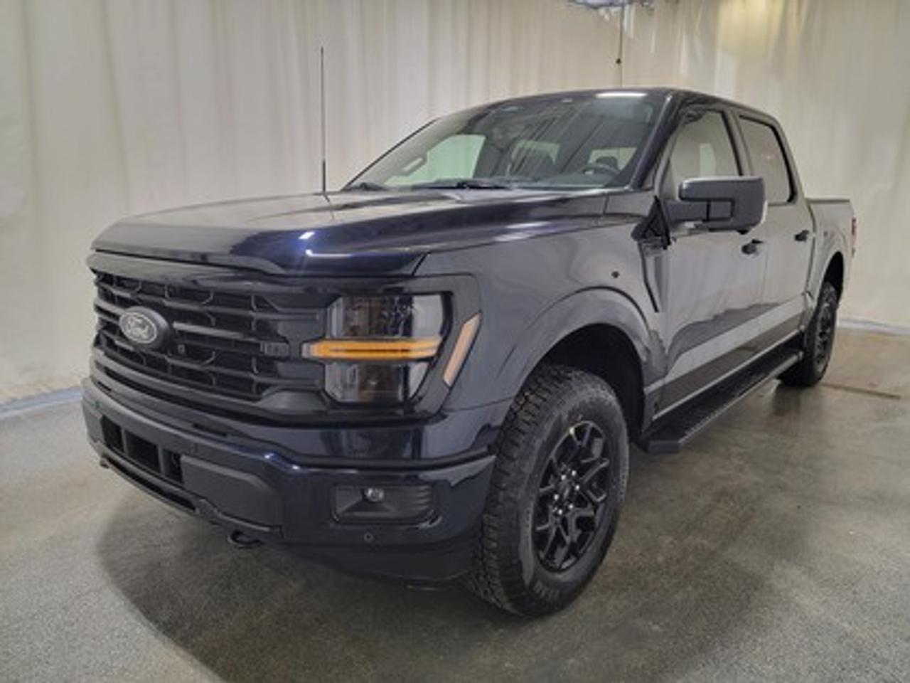 The all-new 2026 Ford F-150 XLT 302A is a statement of style in Antimatter Blue Metallic. Powered by the 2.7L EcoBoost engine, it delivers 325 horsepower and 400 lb-ft of torque, paired with a 10-speed automatic transmission. This truck achieves an impressive, combined fuel economy of 11.8 L/100 km (24 miles per gallon).

This vehicle comes with the All-Weather Packageready to take on any season!
Snow, rain, mud, or sunshinethis vehicle is built for it all! The All-Weather Package adds extra protection where it matters most, with premium mud flaps to shield your paint from road debris, all-weather floor mats to protect your interior from lifes messes, and Xpel paint protection to help guard against those infuriating rock chips. Drive with confidence, knowing your investment is protected from Regina's elements.

Key Features:
12 LCD Captivity Touchscreen
Electronic Power-Assist Steering
Dual-Zone Electronic Auto Temp Control
Cruise Control
Power Windows
AdvanceTrac® With Roll Stability Control
Perimeter Alarm
Ford Co-Pilot360
Lane Keeping System
Rear View Camera
Rear Parking Sensors
Reverse Park Assist
Class IV Trailer Hitch
Power Drivers Seat
Remote Start
SYNC®4
Apple Car Play
18 All Terrain Tires
Bluetooth Connectivity
Black Appearance Package

From navigating Saskatchewan's rugged terrain to hauling gear for your next project, the 2026 Ford F-150 XLT combines capability, technology, and comfort into a trusted workhorse that adapts to your needs. Engineered for durability, the F-150 XLT offers heavy-duty shock absorbers, rear privacy glass, interior worksurface, dual exhaust tips and LED reflector headlamps. Inside, enjoy smart features like power windows, tilt/telescoping steering wheel, and USB charging ports for added convenience. Safety remains a priority with Post Collision Braking, Dynamic Brake Support, and advanced airbag systems.

Bennett Dunlop Ford, proudly serving Regina for over 40 years, is conveniently located at 770 Broad Street. With over 3,500 Google reviews, our reputation reflects our commitment to providing a fast, easy, and enjoyable vehicle-buying experience. We eliminate the hassle with no admin or documentation fees, transparent upfront pricing that lets you shop with total confidence. But were more than just a dealershipwere driven to make a difference by supporting local community initiatives and events that matter to you. Visit Bennett Dunlop Ford today and experience why were Reginas trusted choice for quality vehicles, exceptional service, and a genuine commitment to driving change in our community!