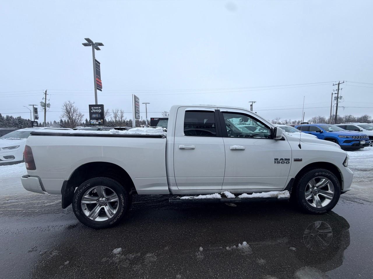 2017 RAM 1500 4WD Quad Cab 6.4 Ft Box Sport Photo