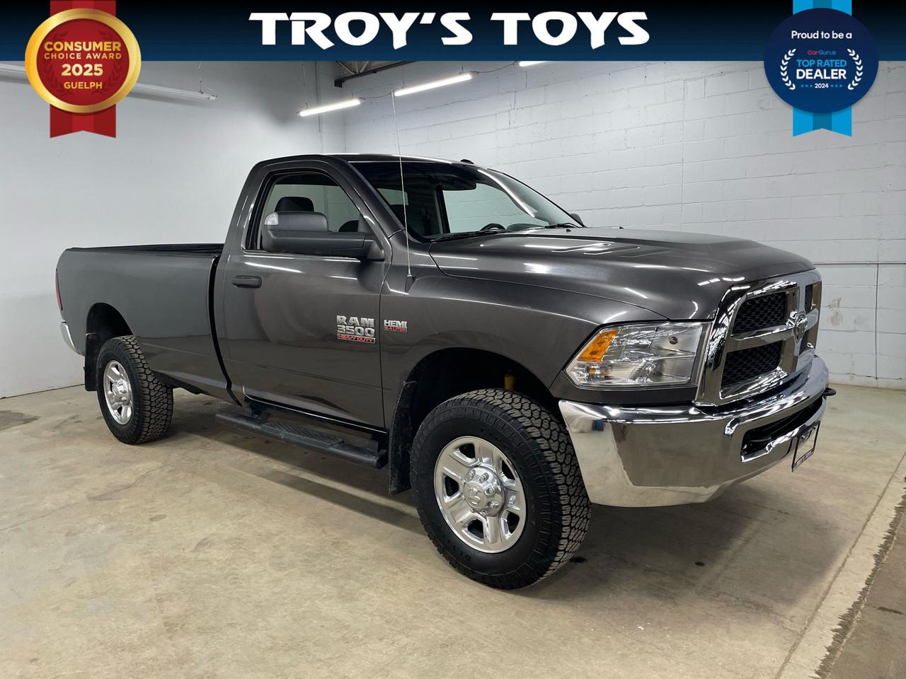 <p>Looking for a heavy-duty workhorse that can handle anything you throw at it? Then check out this rugged 2016 RAM 3500 4WD Regular Cab 140.5 ST, now available at Troys Toys. This beast is ready to tackle tough jobs with its powerful 6.4L V8 engine, offering the muscle you need for towing, hauling, and everything in between. This truck is built for reliability and longevity.</p><p>This capable pickup comes in a timeless grey exterior and a comfortable grey interior. Its equipped with a smooth-shifting automatic transmission and a robust 4-wheel drive system, ensuring you can confidently navigate any terrain. With only 127,638km on the odometer, this RAM 3500 has plenty of life left to offer. Visit Troys Toys today and see this truck up close and personal!</p><p>Here are a few of this RAM 3500s standout features:</p><ul><li><strong>Commanding 4-Wheel Drive:</strong> Conquer any road condition with confidence.</li><li><strong>Powerful 6.4L V8 Engine:</strong> Get the power and torque you need to get the job done.</li><li><strong>Durable Regular Cab:</strong> A work-ready configuration for maximum utility.</li><li><strong>Reliable Automatic Transmission:</strong> Easy and smooth shifting for a comfortable driving experience.</li><li><strong>Robust Pickup Truck Design:</strong> Built tough to handle demanding tasks.</li></ul><p><strong><em>Powered by AutoIntelligence&trade;</em></strong> Vehicle information has been generated using artificial intelligence and is provided for informational purposes only. While efforts are made to ensure accuracy, please confirm all details directly with the dealer.</p>