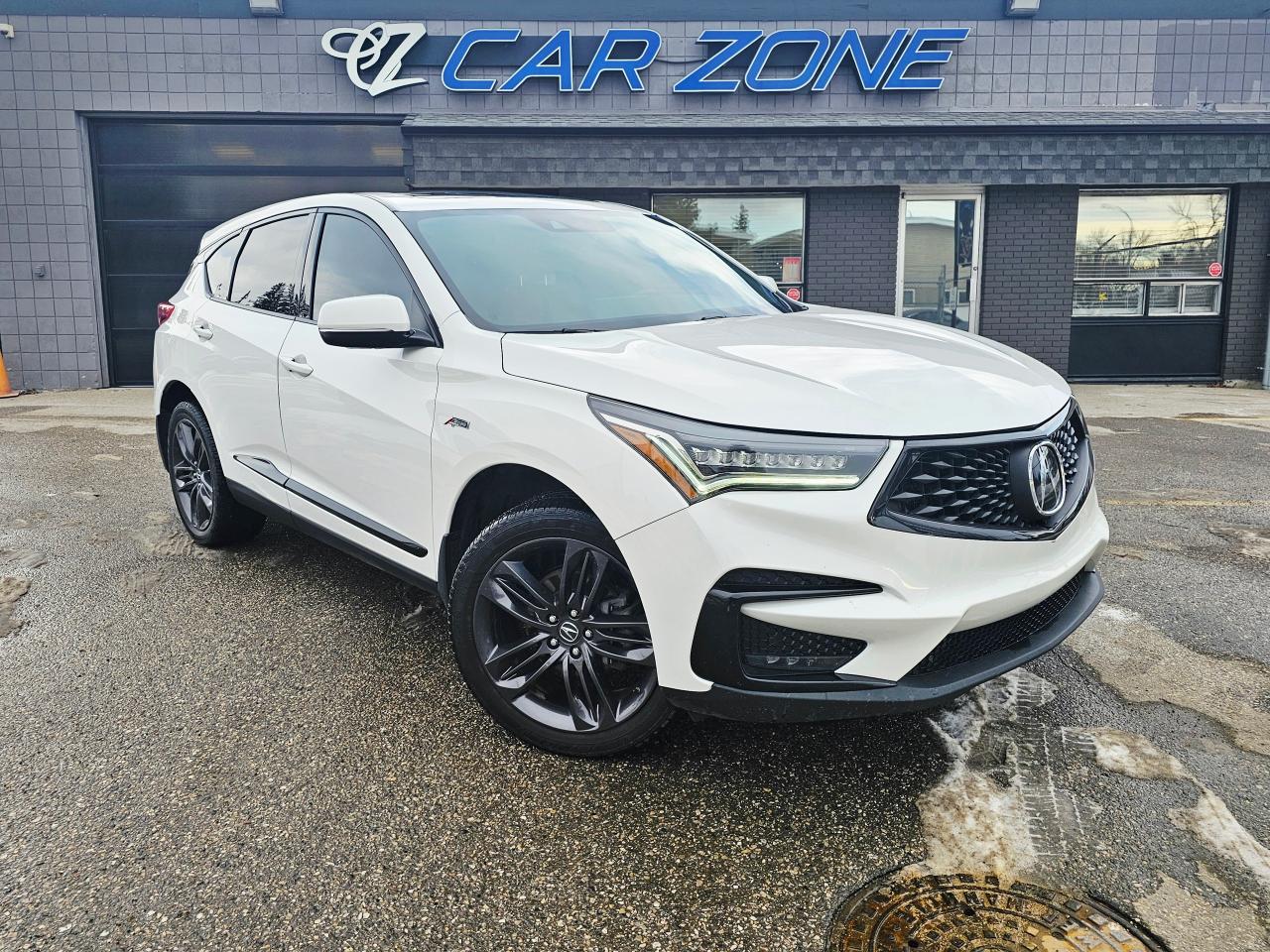 <p>Looking for a stylish and sporty SUV that turns heads? Feast your eyes on this stunning 2020 Acura RDX A-Spec Package, available now at Car Zone! This head-turning SUV boasts a pristine white exterior that perfectly complements its bold red interior, ensuring youll arrive in style wherever your adventures take you. With only 151,026km on the odometer, this meticulously maintained Acura is ready to provide you with years of driving pleasure. The RDX A-Spec Package is renowned for its premium features and exhilarating performance, making it the perfect choice for those who demand both luxury and excitement.</p><p>Under the hood, youll find a responsive 2L V4 Turbo engine paired with an automatic transmission, delivering impressive power and seamless shifts. The all-wheel-drive system provides confident handling in all weather conditions, making it ideal for navigating Canadian roads year-round. Step inside and experience the premium comfort and advanced technology that Acura is known for. This RDX is more than just a vehicle; its a statement.</p><p>Here are five features that make this Acura RDX truly special:</p><ul><li><strong>Sporty A-Spec Package:</strong> Get ready to stand out with the aggressive styling of the A-Spec package, including unique exterior accents and a sporty interior.</li><li><strong>Turbocharged Engine:</strong> Experience thrilling acceleration and responsive performance with the powerful 2L turbo engine.</li><li><strong>All-Wheel Drive:</strong> Conquer any road condition with the confidence of Acuras renowned all-wheel-drive system.</li><li><strong>Luxurious Red Interior:</strong> Indulge in the premium comfort and style of the striking red interior.</li><li><strong>Advanced Technology:</strong> Enjoy a wealth of modern features that enhance your driving experience and keep you connected.</li></ul><p>Looking for Your Dream Car? Call Car Zone Today!</p><p>Thanks for viewing our Car Zone inventory. All of our vehicles come fully detailed with a Carfax and a mechanical fitness assessment. Drive this home today! Easy financing options. All credit welcome.<a href=http://www.carzonecalgary.com/financing/>&nbsp;</a><strong><a href=http://www.carzonecalgary.com/financing/>APPLY NOW</a>&nbsp;</strong>We even take trades. Same day approvals at&nbsp;<a href=http://www.carzonecalgary.com/><strong>CARZONECALGARY</strong></a> or visit us in person at 2036 36 Street SE Calgary for a hassle free test drive. Let our friendly team of experts book an appointment with you and show you the Car Zone difference! AMVIC licensed dealer.&nbsp;</p>