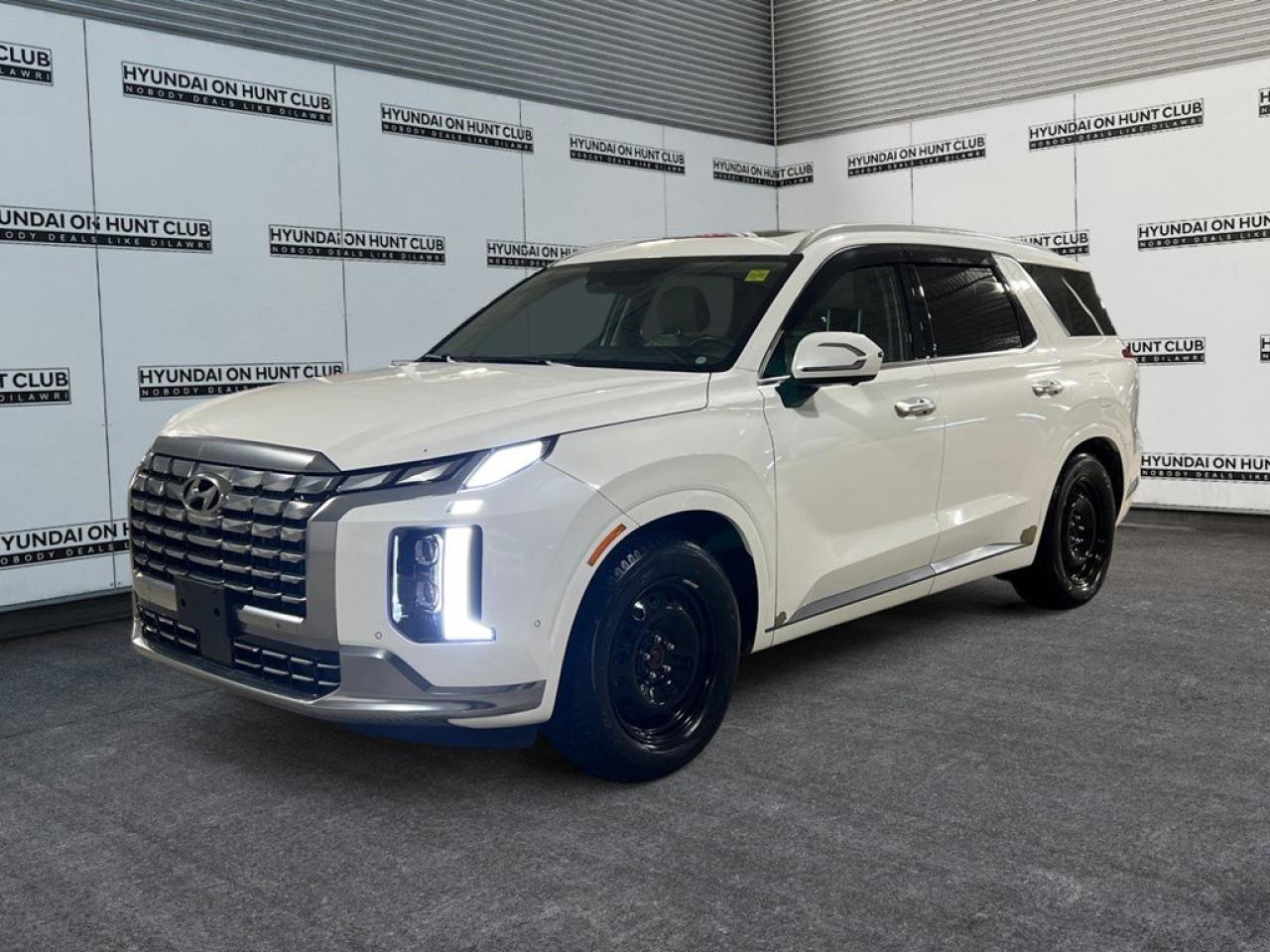 The 2023 Hyundai Palisade Ultimate Calligraphy in a stunning white finish with AWD delivers exceptional handling and stability, making it perfect for Canadian roads and weather conditions. As a sophisticated SUV, it stands out with its elegant styling and commanding presence. The exterior design is both robust and refined, capturing attention with its bold lines and impressive grille. Inside, the Palisade features a spacious and comfortable cabin with a chic beige interior, offering ample room for up to seven passengers, ensuring everyone travels in luxury and comfort. Equipped with cutting-edge technology, this SUV includes an intuitive infotainment system featuring a large touchscreen display to keep you seamlessly connected. Safety is paramount with features such as advanced driver assistance systems and a comprehensive array of protective technologies, offering peace of mind for both driver and passengers. This Hyundai Palisade is ideal for families and individuals who crave reliability paired with opulence in their everyday vehicle. Contact us today to learn more about how this stunning SUV can enhance your driving experience.