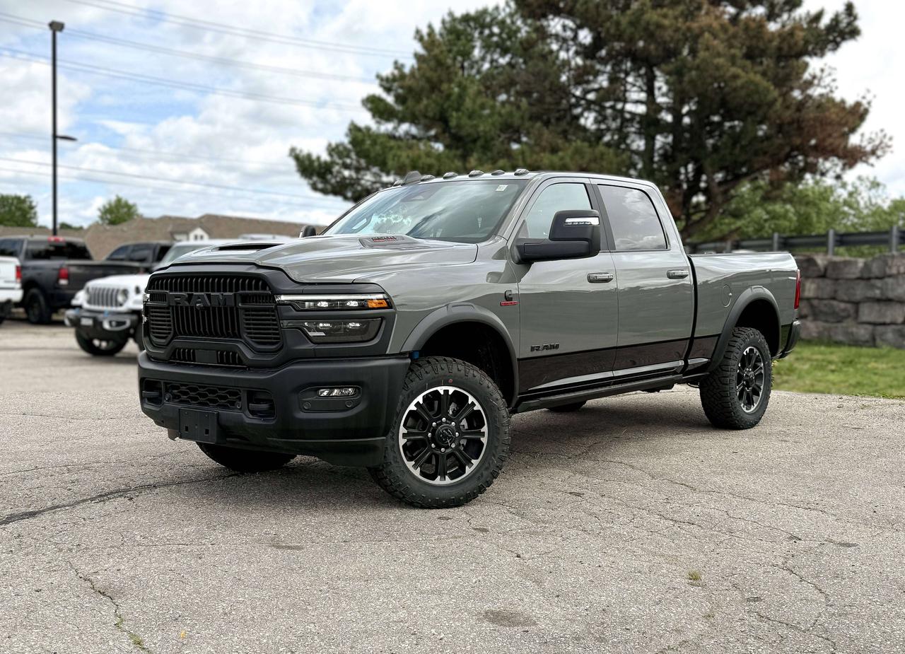 With diesel muscle and off-road tuning, our New 2026 RAM 2500 Rebel Crew Cab 4X4 in Ceramic Grey Clearcoat delivers enhanced capability for heavy hauls. Motivated by a High-Output TurboCharged 6.7 Litre Cummins 6 Cylinder supplying 430hp and 850lb-ft of torque to an 8 Speed Automatic transmission. A rugged Rebel suspension, hill-descent control, and electronic limited-slip differential raise the bar for off-road performance in this Four Wheel Drive truck, which shows off LED lighting, fog lamps, a Mopar sport hood, powder-coated bumpers, black alloy wheels, matching fender flares, multifunction trailering mirrors, a 115V/400W outlet, and a Class V receiver hitch. Highlighting our Rebel cabin are heated power cloth front seats embossed with distinctive tread-pattern designs. You can also enjoy a heated and wrapped steering wheel, dual-zone automatic climate control, keyless access and ignition, remote start, and power-adjustable pedals. A 12-inch driver display and an 8.4-inch touchscreen help create a high-tech environment with Off-Road Info Pages, full-color navigation, Wi-Fi compatibility, Alexa Built-in, Android Auto&reg;/Apple CarPlay&reg;, voice command, Bluetooth&reg;, and six-speaker audio. RAM supplies top-shelf safety measures, including a rearview camera, parking sensors, hill start assistance, tire pressure monitoring, trailer sway control, and more. That makes our 2500 Rebel a great way to boost your driving! Save this Page and Call for Availability. We Know You Will Enjoy Your Test Drive Towards Ownership!