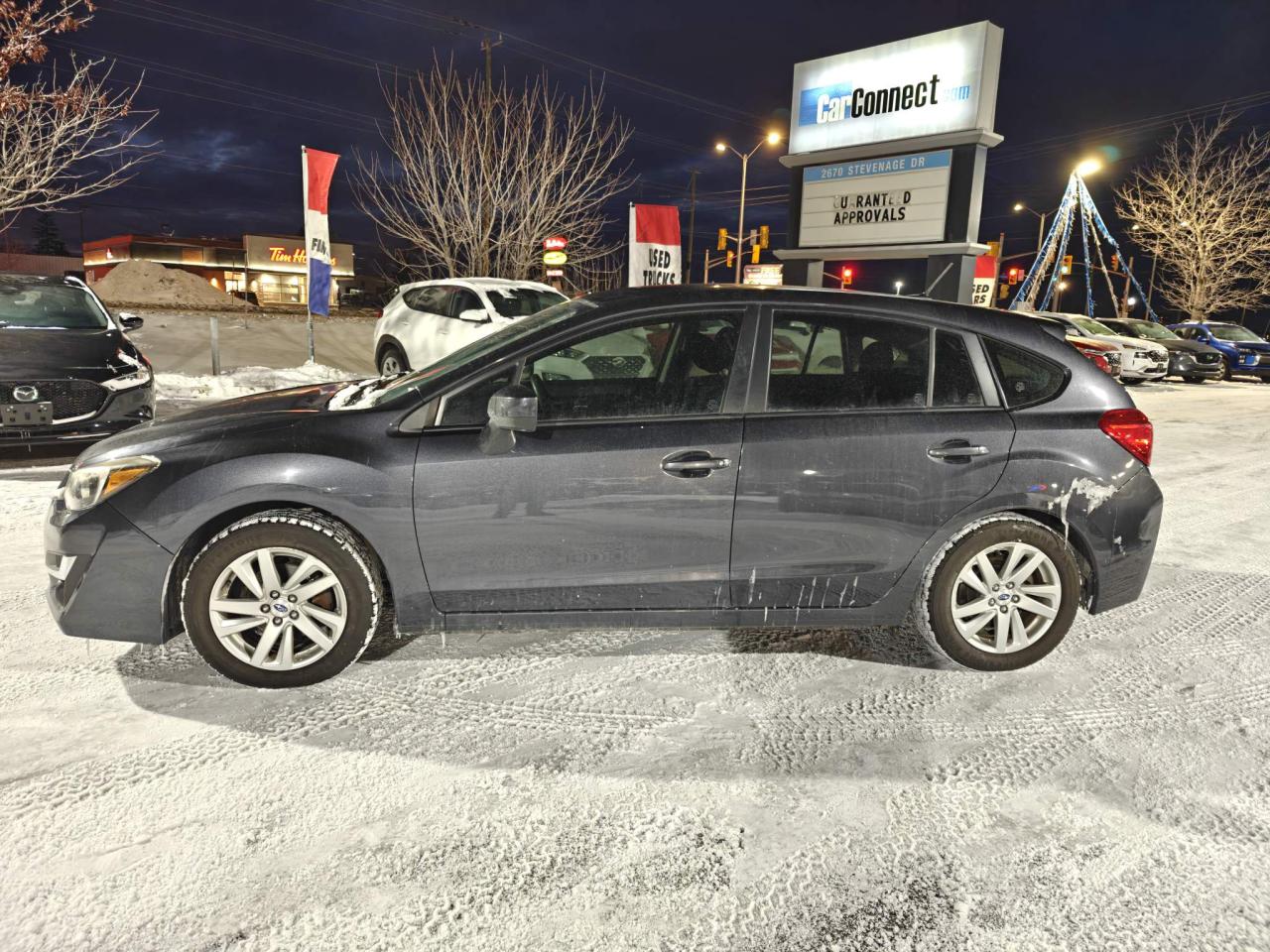 2016 Subaru Impreza 2.0i Touring Package (CVT) 4dr Hatchback Photo