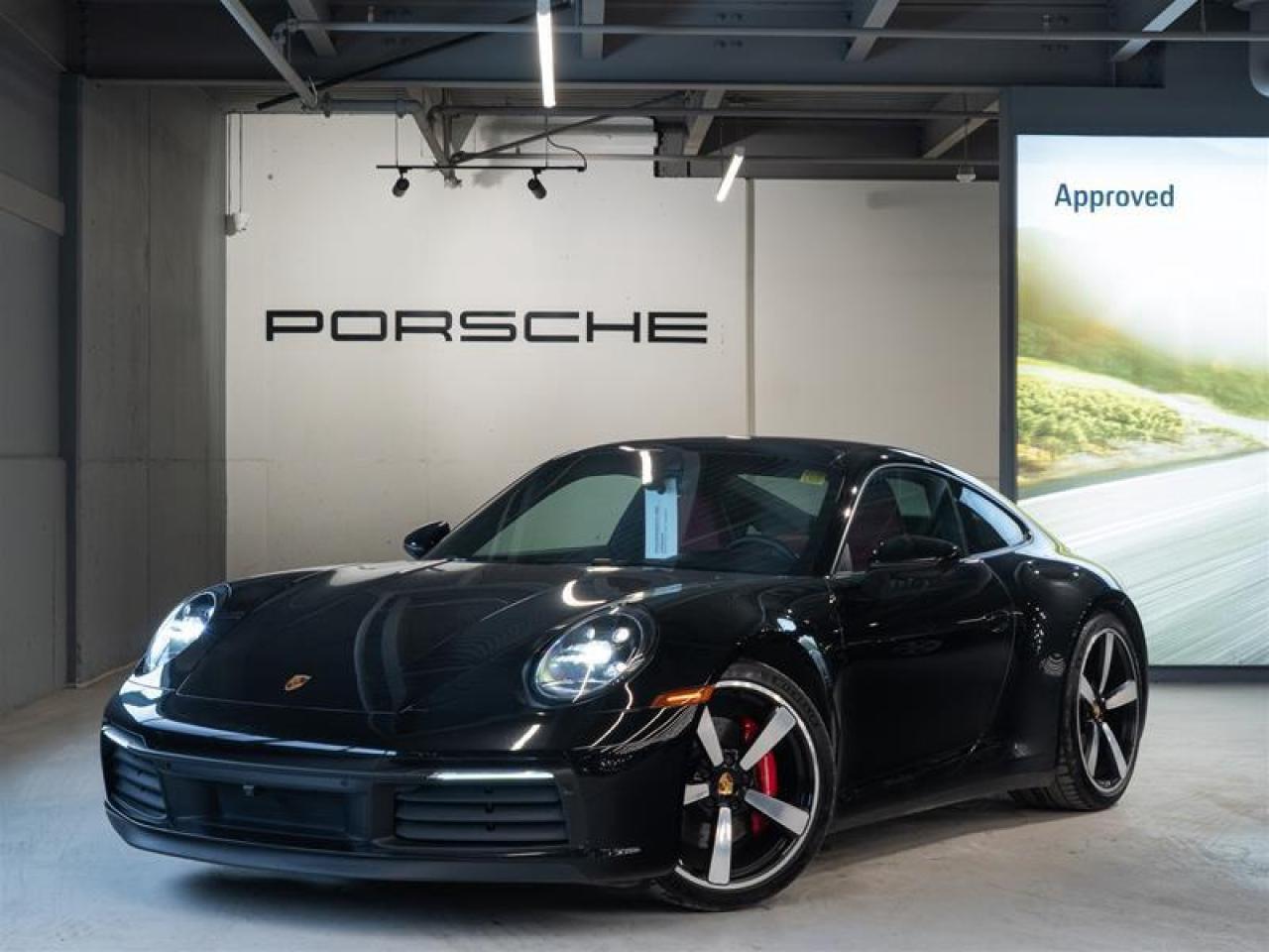 ***Leasing Options Available on Certified Pre-Owned Porsches***  The Porsche that you’ve always wanted. This 2023 911 Carrera 4S (MY23) has a Clean CarFax Report. With Leather Interior in Black/Bordeaux Red ($4,860), Premium Package ($6,100), Sport Package ($6,230), Sport Chrono Package with Porsche Design Subsecond Clock ($1,270), Electric Slide/Tilt Sunroof in Glass ($2,280), Under Door Puddle Light Projectors ($190), Exclusive Design Fuel Cap ($190), Preparation for Roof Transport System ($70), Front Axle Lift System ($3,150), Rear Axle Steering ($2,390), Wheels Painted in High Gloss Black ($1,480), Locking Wheel Bolts ($70), 20/21 Carrera Exclusive Design Wheels ($3,000), Adaptive Sport Seats Plus (18-way) with Memory Package ($3,720), Heated GT Sport Steering Wheel in Leather ($370), 930 Leather Package ($1,700), Porsche Crest on Headrests (Front) ($330), and Door-Sill Guards in Dark Silver Brushed Aluminum, Illuminated ($1,030), this is the car for you! Look for the Porsche Approved seal when buying a pre-owned Porsche. Porsche Approved Pre-Owned Cars are inspected in compliance with our 111-point checklist and any work required is performed using only 100% Porsche Genuine Parts. As proof of the trust that we have in the quality of our vehicles, every certified pre-owned car comes with a minimum of 24 months Porsche Approved Warranty and Porsche Roadside Assistance. The Porsche Approved Warranty covers all components of your Porsche and offers the same level of security as our new car warranty. Luxury Tax is not charged on Certified Pre-Owned vehicles. Call us at 613-749-4275 and ask to speak to one of our Porsche Brand Executives. Serving the Ottawa & Gatineau region. *** Options de location disponibles pour les Porsche doccasion certifiées *** La Porsche de vos rêves. Cette voiture 2023 911 Carrera 4S (MY23) a un bon rapport d’historique de véhicule de CarFax. Grâce à Leather Interior in Black/Bordeaux Red ($4,860), Premium Package ($6,100), Sport Package ($6,230), Sport Chrono Package with Porsche Design Subsecond Clock ($1,270), Electric Slide/Tilt Sunroof in Glass ($2,280), Under Door Puddle Light Projectors ($190), Exclusive Design Fuel Cap ($190), Preparation for Roof Transport System ($70), Front Axle Lift System ($3,150), Rear Axle Steering ($2,390), Wheels Painted in High Gloss Black ($1,480), Locking Wheel Bolts ($70), 20/21 Carrera Exclusive Design Wheels ($3,000), Adaptive Sport Seats Plus (18-way) with Memory Package ($3,720), Heated GT Sport Steering Wheel in Leather ($370), 930 Leather Package ($1,700), Porsche Crest on Headrests (Front) ($330), and Door-Sill Guards in Dark Silver Brushed Aluminum, Illuminated ($1,030), cette voiture est parfaite pour vous! Trouvez le sceau d’approbation de Porsche lorsque vous achetez une Porsche d’occasion. Les voitures d’occasion approuvées par Porsche sont inspectées conformément à notre liste de vérification de 111 points. Tout travail requis est effectué en utilisant uniquement des pièces d’origine Porsche. Comme preuve de la confiance que nous avons dans la qualité de nos véhicules, chaque voiture d’occasion certifiée fait l’objet d’une garantie d’au moins 24 mois approuvée par Porsche et de l’assistance routière Porsche. La garantie approuvée par Porsche couvre tous les composants de votre Porsche et offre le même niveau de sécurité que notre garantie pour les véhicules neufs. La taxe de luxe n’est pas appliquée aux véhicules d’occasion certifiés. Appelez-nous au 613-749-4275 pour parler à l’un de nos directeurs de marque Porsche. Au service de la région d’Ottawa et du Gatineau.