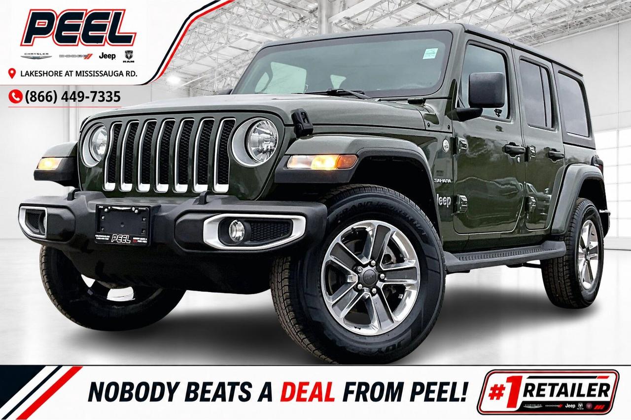 COME SEE WHY NOBODY BEATS A DEAL FROM PEEL! Your Source for ALL make and models used cars and trucks.

2021 Jeep Wrangler 4-Door Sahara 4X4 | 2.0L Turbocharged I-4 Engine | Sarge Green | Heated Cloth Bucket Seats | Uconnect 7" Touchscreen Display | Heated Seats | Heated Steering Wheel | Remote Start | Apple CarPlay & Android Auto | 8-speaker Sound System w/ Overhead Sound Bar | Black Freedom 3-piece Hard Top | Dual-zone Automatic Climate Control | Mopar Side Steps

Clean Carfax

Start your Jeep journey the right way with this 2021 Wrangler Sahara in Sarge Green, priced to sell and ready for everyday comfort, with heated cloth bucket seats, dual zone automatic climate control, a heated steering wheel, and remote start that turns winter mornings into easy departures. Uconnect on the 7 inch touchscreen pairs with Apple CarPlay and Android Auto to keep maps, calls, and music simple so you can focus on the drive. Outside, the four door Sahara body looks classic and purposeful in Sarge Green, while the responsive 2.0L turbo and proven 4X4 traction deliver confident control in city slush, cottage gravel, and summer rain. With Clean Carfax history and a smart spec that gives you everything you need without paying for what you do not, this Sahara is the right Wrangler at the right price.
______________________________________________________

FREE CarFax included! Click the CarFax link in the listing to view the report.

Our advertised prices are for consumers/end users only and are not intended for dealer, wholesale, exporter, or broker purchases.
______________________________________________________

Peel Chrysler is based in Port Credit, Mississauga, and proudly serves customers across Ontario and Canada, including Toronto, Oakville, North York, Richmond Hill, Ajax, Hamilton, Niagara Falls, Brampton, Scarborough, Vaughan, London, Windsor, Cambridge, Kitchener, Waterloo, Brantford, Sarnia, Pickering, Huntsville, Milton, Woodbridge, Aurora, Newmarket, Orangeville, Georgetown, Markham, North Bay, Sudbury, Barrie, Oshawa, Kingston, Innisfil, and surrounding areas. Browse our selection of used cars, trucks, SUVs, vans, Ram, Jeep, Dodge, Chrysler, FIAT, and all makes and models at peelchrysler.com.
______________________________________________________

Disclaimer: Prices are for consumer/end-user purchases only. Advertised prices are all-in and include all dealer fees and charges, including the $499 loan processing fee where applicable, except HST, Fuel and Licensing, unless otherwise stated. Payments, rates, and terms are subject to approved credit and may change without notice. If a trade-in has an outstanding loan balance and Peel Chrysler is required to facilitate the lien payout, a $349 lien payout fee applies. Most pre-owned vehicles originally come with two keys; however, all Peel Chrysler pre-owned vehicles come standard with one key unless otherwise stated. Vehicle images may be digitally adjusted or enhanced for presentation purposes and may not always reflect the exact appearance of the vehicle. While we make every effort to ensure accuracy, vehicle details, features, options, materials, history, specifications, pricing, availability, and CarFax information should be verified with Peel Chrysler before purchase.