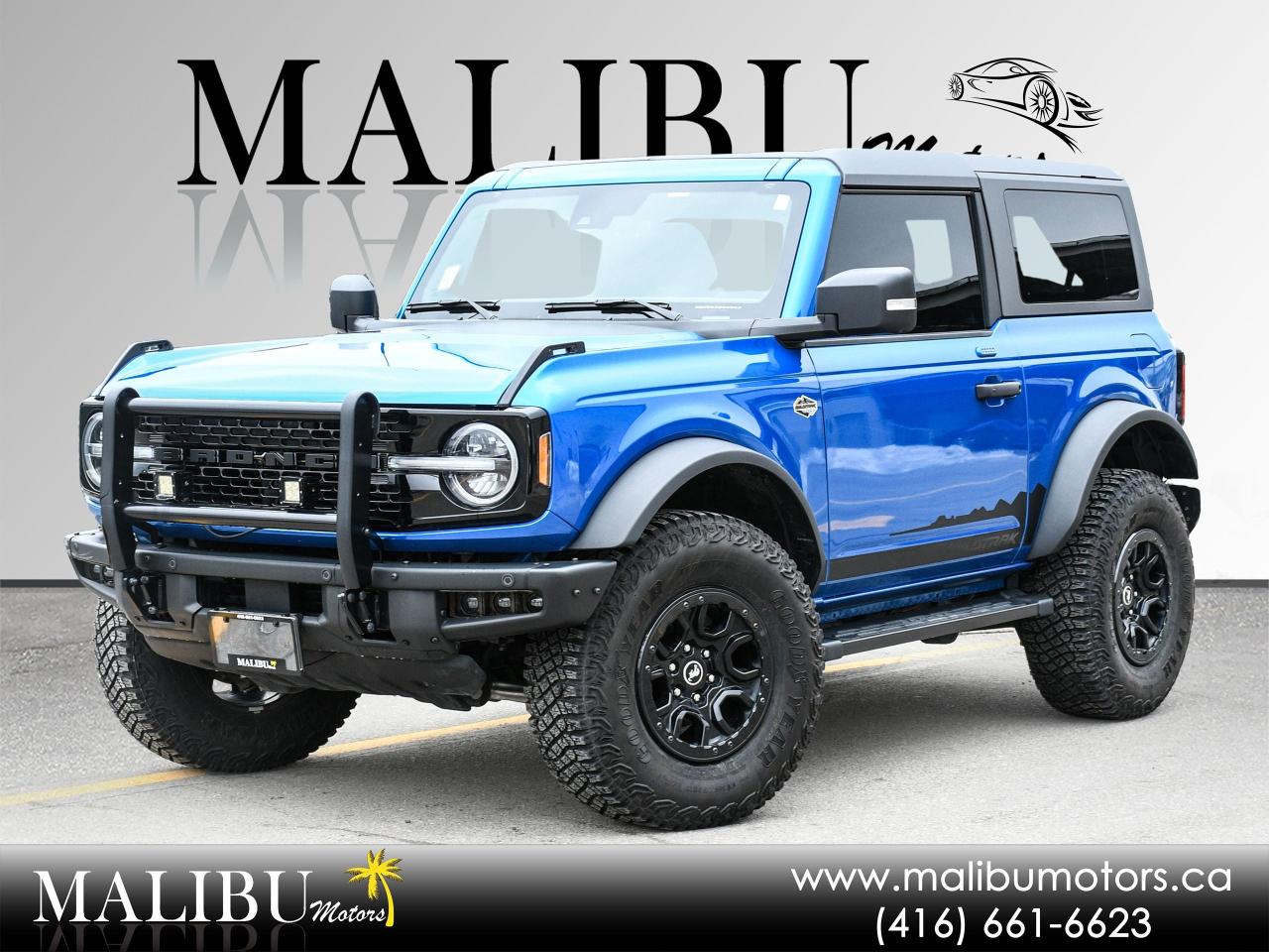 <p>FINISHED ION BLUE ON SAND/BLACK INTERIOR, SOUND INSULATED ROOF, REMOVAL TOP, 2 Smart Charging USB Ports In Dashboard, 1 A and 1 C, 12 LCD Capacitive Touchscreen w/Swipe Capability, Evasive Steering Assist, Heated Steering Wheel, Adaptive Cruise Control, Additional Sound Deadening, Information on Demand Panel, Wireless Charging Pad, Radio: B&O Sound System by Bang & Olufsen, 10 Speakers w/Subwoofer, Front Parking Sensors, 360-Degree Camera, Universal Garage Door Opener, Sideview Mirrors, LED approach lamps and LED spotlight, &nbsp;Connected Built-In Navigation, 3 years of connected services, live traffic, predictive destinations and route guidance, Navigation service requires SYNC4 and FordPass Connect, complimentary connect service and the FordPass app (see FordPass terms for details), Customer receives a complimentary 3-year trial of navigation services when an eligible vehicle is added to a members FordPass account, Trial period begins w/new vehicle warranty start date, At the end of the complimentary period, access to connected navigation services will be discontinued, Connected service and features depend on compatible Bell network availability, Evolving technology/cellular networks/vehicle capability may limit functionality and prevent operation of connected features, FordPass App, compatible w/select smartphone platforms, is available via a download, Message and data rates may apply<br>ADDITIONAL EQUIPMENT<br>BRUSH GUARD &bull; 68B<br>Custom accessory, pre-installed<br>WILDTRAK BODYSIDE GRAPHIC &bull; 50C<br>Selection of this feature adds the Wildtrak bodyside graphics to the vehicle<br>FRONT LICENSE PLATE BRACKET &bull; 153-0<br>Standard when required by province (Ontario, Manitoba, British Columbia), Optional in all other provinces/territories<br>BASE LED HEADLAMPS &bull; 91V<br>LED taillamps, This is in place of signature lighting<br>KEYLESS ENTRY KEYPAD &bull; 63C<br>Custom accessory, pre-installed<br>CONNECTED BUILT-IN NAVIGATION &bull; 59B<br>3 years of connected services, live traffic, predictive destinations and route guidance, Navigation service requires SYNC4 and FordPass Connect, complimentary connect service and the FordPass app (see FordPass terms for details), Customer receives a complimentary 3-year trial of navigation services when an eligible vehicle is added to a members FordPass account, Trial period begins w/new vehicle warranty start date, At the end of the complimentary period, access to connected navigation services will be discontinued, Connected service and features depend on compatible Bell network availability, Evolving technology/cellular networks/vehicle capability may limit functionality and prevent operation of connected features, FordPass App, compatible w/select smartphone platforms, is available via a download, Message and data rates may apply<br>FRONT ROW TOP PANELS & DOOR STORAGE BAGS &bull; 87E<br>Custom accessory, pre-installed, Hard tops contain the front row top panels storage bag, this option adds the door storage bag, The door storage bags are unique to the number of doors,<br>CASH PRICE 58999. FINANCED PRICE 56999.00 TAXES AND LICENSE ARE EXTRA PLEASE CALL AHEAD TO BOOK AN APPOINTMENT&nbsp;</p>