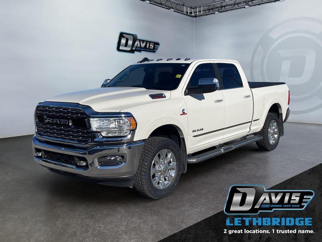 <b>Running Boards, Navigation, Wireless Charging, Cooled Seats, Leather Seats!<br /> <br /></b><br /> The 2022 Ram 2500 Limited is a powerful and luxurious heavy-duty pickup, built for towing, hauling, and off-road adventures. Powered by the 6.7L Cummins Turbo Diesel I6 paired with an automatic 6-speed transmission, it delivers exceptional torque and reliability for demanding workloads. This crew cab 4x4 comes in Pearl White with chrome accents, LED lighting, and 20-inch satin carbon wheels for a bold presence.<br /><br />Inside, enjoy premium Limited leather bucket seats with heating and ventilation, dual-zone climate control, Uconnect® 5 NAV with 12-inch touchscreen, Apple CarPlay, Android Auto, and wireless charging. The cabin is loaded with storage solutions, including under-seat compartments and full-length premium console, plus luxury accents like real wood trim and leather-wrapped steering wheel.<br /><br />Safety and convenience features include ParkView® rear backup camera, ParkSense® front/rear park assist, blind-spot monitoring, trailer sway damping, 5th wheel/gooseneck prep, and heavy-duty suspension with air-leveling for optimal ride and handling. Rugged, capable, and refined, the 2022 Ram 2500 Limited is engineered for both work and comfort.<br /> <br />To apply right now for financing use this link: <a href=https://lethbridge.davisdodge.ca/free-credit-check/ target=_blank rel=nofollow noopener noreferrer>https://lethbridge.davisdodge.ca/free-credit-check/</a><br /><br /> <br /><br />Locally Owned & Trusted for Over 35 Years  Davis Dodge in Lethbridge, AB <br /><br /> At Davis Dodge, weve proudly served the Lethbridge community for more than 35 years, offering an unparalleled car buying experience. Dont just take our word for itour Google reviews speak volumes about our commitment to exceptional service. <br /><br /> Delivery & At-Home Test Drives: Convenient options to suit your lifestyle. <br /><br /> Flexible Financing for Everyone: Get the vehicle you need with financing solutions tailored to your situation. <br /><br /> Full Mechanical Inspections & Professional Cleaning: Every vehicle is thoroughly inspected and cleaned before it hits our lot.<br /><br /> We take all makes and models on trade and offer competitive pricing with inventory that changes daily. Whether you're shopping for a Chrysler, Dodge, Jeep, RAM, or FIAT, our AMVIC Licensed dealership makes it easy to browse, buy, and drive away.<br /><br /> Located in Lethbridge, AB, we proudly serve customers in Fort Macleod, Taber, Claresholm, and Coaldale. Shop online or visit us today to experience the best in sales, service, and selection. Standard bank rates apply; taxes are additional.<br /><br /> Vehicle pricing offer shown expires 2026-04-30. <br /> Come by and check out our fleet of 70+ used cars and trucks and 130+ new cars and trucks for sale in Lethbridge. o~o