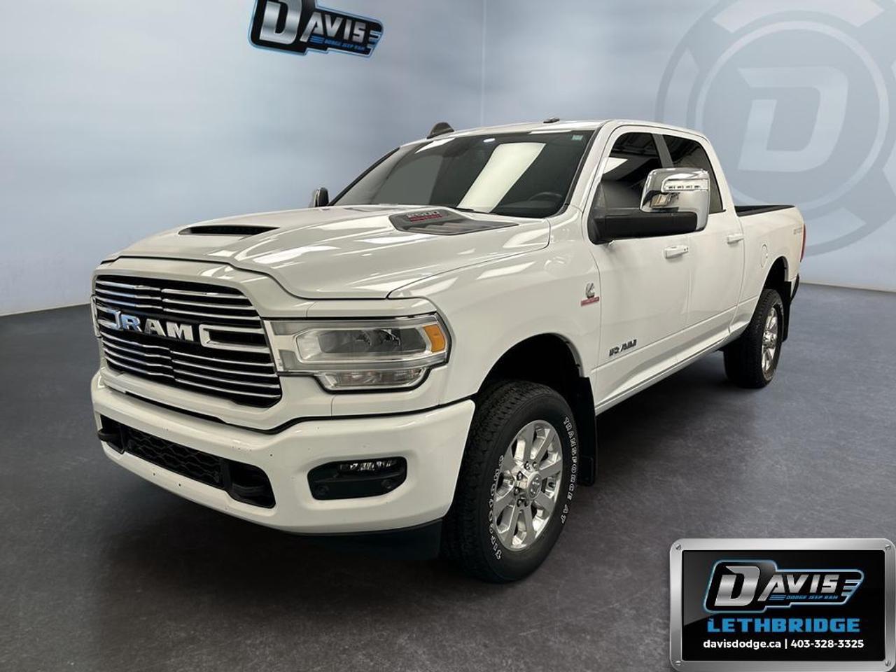 <b>Heavy Duty Suspension, Heated Steering Wheel, Tow Package, Navigation, Apple CarPlay!<br /> <br /></b><br /> The 2023 Ram 2500 Laramie is a rugged yet refined heavy-duty pickup built for power, comfort, and capability. Equipped with the 6.7L Cummins Turbo Diesel I6 and 6-speed automatic transmission, it delivers exceptional towing and hauling performance. This crew cab 4x4 features a 6,000 lb front axle, 11.5-inch single rear axle, and heavy-duty suspension for maximum stability on any terrain.<br /><br />Inside, enjoy premium Laramie leather-trimmed bucket seats with heating and ventilation, dual-zone climate control, Uconnect® 5 NAV with 12-inch touchscreen, Apple CarPlay, Android Auto, Alexa Built-In, and wireless charging. The cabin also offers advanced storage solutions, LED interior lighting, and luxury accents including wood and leather trim.<br /><br />Safety and convenience are front and center with ParkView® rear backup camera, ParkSense® front/rear park assist, blind-spot monitoring, trailer tow prep, and selectable tire fill alerts. Finished in Bright White Clear Coat with 20-inch polished aluminum wheels, the 2023 Ram 2500 Laramie combines capability, luxury, and modern technology for drivers who demand it all.<br /> <br />To apply right now for financing use this link: <a href=https://lethbridge.davisdodge.ca/free-credit-check/ target=_blank rel=nofollow noopener noreferrer>https://lethbridge.davisdodge.ca/free-credit-check/</a><br /> <br /><br />Locally Owned & Trusted for Over 35 Years  Davis Dodge in Lethbridge, AB <br /><br /> At Davis Dodge, weve proudly served the Lethbridge community for more than 35 years, offering an unparalleled car buying experience. Dont just take our word for itour Google reviews speak volumes about our commitment to exceptional service. <br /><br /> Delivery & At-Home Test Drives: Convenient options to suit your lifestyle. <br /><br /> Flexible Financing for Everyone: Get the vehicle you need with financing solutions tailored to your situation. <br /><br /> Full Mechanical Inspections & Professional Cleaning: Every vehicle is thoroughly inspected and cleaned before it hits our lot.<br /><br /> We take all makes and models on trade and offer competitive pricing with inventory that changes daily. Whether you're shopping for a Chrysler, Dodge, Jeep, RAM, or FIAT, our AMVIC Licensed dealership makes it easy to browse, buy, and drive away.<br /><br /> Located in Lethbridge, AB, we proudly serve customers in Fort Macleod, Taber, Claresholm, and Coaldale. Shop online or visit us today to experience the best in sales, service, and selection. Standard bank rates apply; taxes are additional.<br /><br /> Vehicle pricing offer shown expires 2026-07-31. <br /> Come by and check out our fleet of 50+ used cars and trucks and 110+ new cars and trucks for sale in Lethbridge. o~o