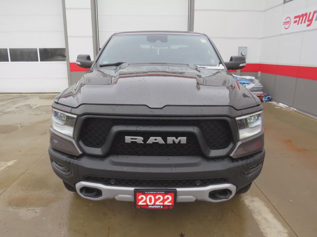 2022 RAM 1500 Rebel (**SAFETY/CERTIFIED!!**4WD**RUNNING BOARDS**TRAILER HITCH**TONNEAU COVER**REMOTE START**BRAKE CONTROLLER**FRONT TOW HOOKS**NAVIGATION**FOG LIGHTS**WIRELESS PHONE CHARGING**HEATED FRONT AND REAR SEATS**REVERSE CAMERA**LEATHER**SUNROOF**PUSH BUTTON ST Photo
