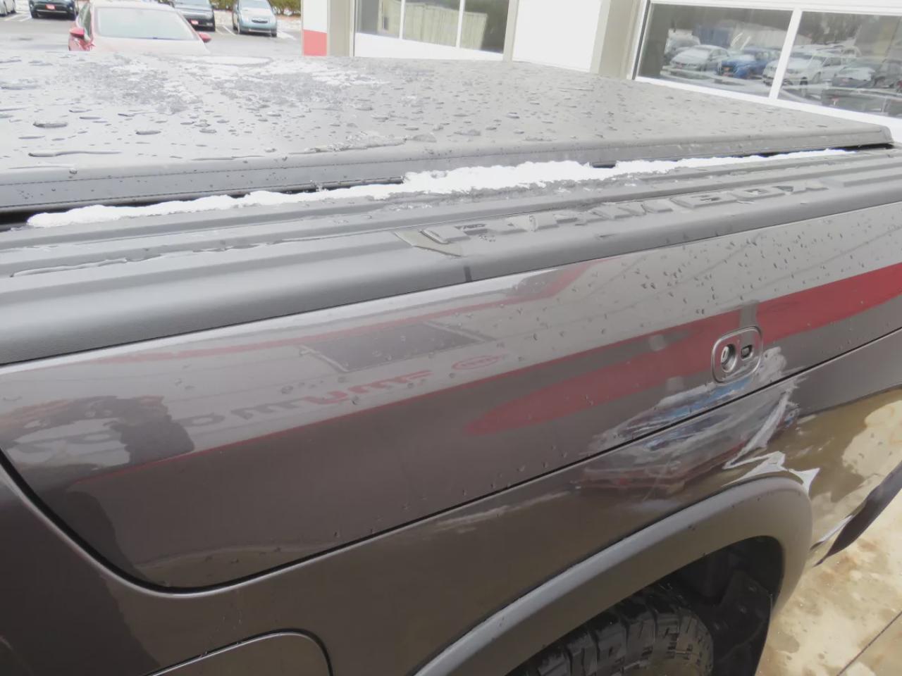 2022 RAM 1500 Rebel (**SAFETY/CERTIFIED!!**4WD**RUNNING BOARDS**TRAILER HITCH**TONNEAU COVER**REMOTE START**BRAKE CONTROLLER**FRONT TOW HOOKS**NAVIGATION**FOG LIGHTS**WIRELESS PHONE CHARGING**HEATED FRONT AND REAR SEATS**REVERSE CAMERA**LEATHER**SUNROOF**PUSH BUTTON ST Photo