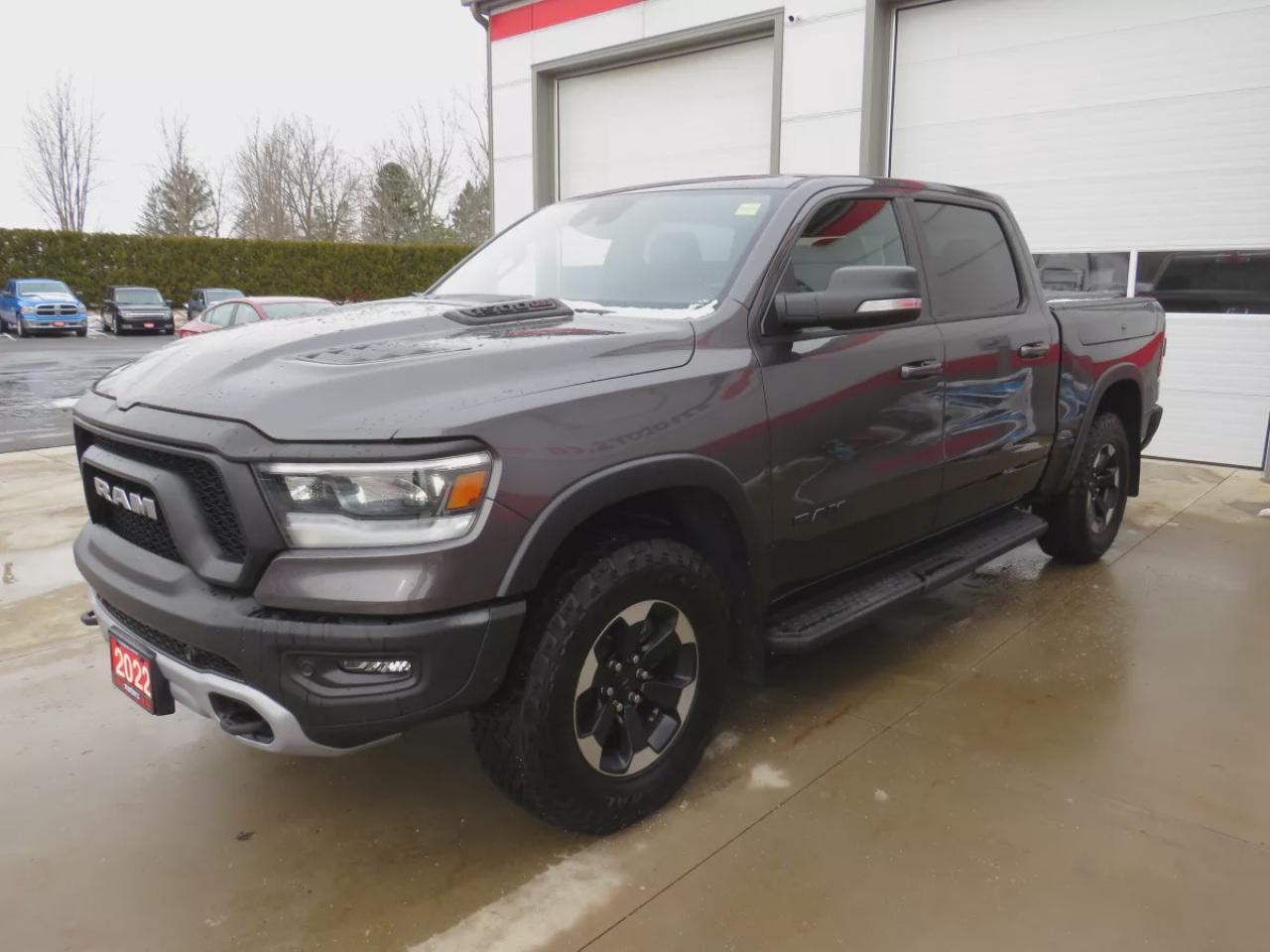 2022 RAM 1500 Rebel (**SAFETY/CERTIFIED!!**4WD**RUNNING BOARDS**TRAILER HITCH**TONNEAU COVER**REMOTE START**BRAKE CONTROLLER**FRONT TOW HOOKS**NAVIGATION**FOG LIGHTS**WIRELESS PHONE CHARGING**HEATED FRONT AND REAR SEATS**REVERSE CAMERA**LEATHER**SUNROOF**PUSH BUTTON ST Photo