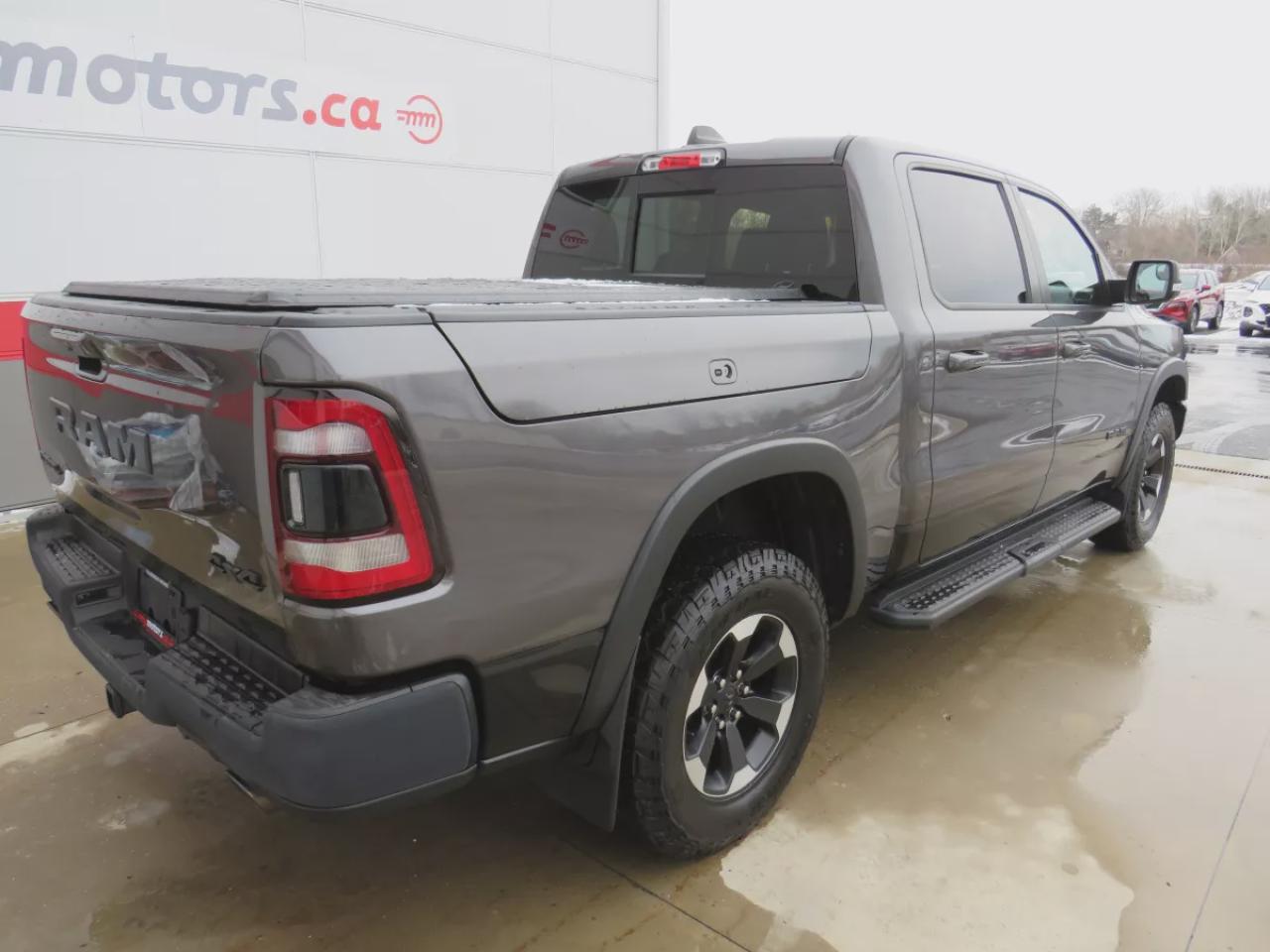 2022 RAM 1500 Rebel (**SAFETY/CERTIFIED!!**4WD**RUNNING BOARDS**TRAILER HITCH**TONNEAU COVER**REMOTE START**BRAKE CONTROLLER**FRONT TOW HOOKS**NAVIGATION**FOG LIGHTS**WIRELESS PHONE CHARGING**HEATED FRONT AND REAR SEATS**REVERSE CAMERA**LEATHER**SUNROOF**PUSH BUTTON ST Photo