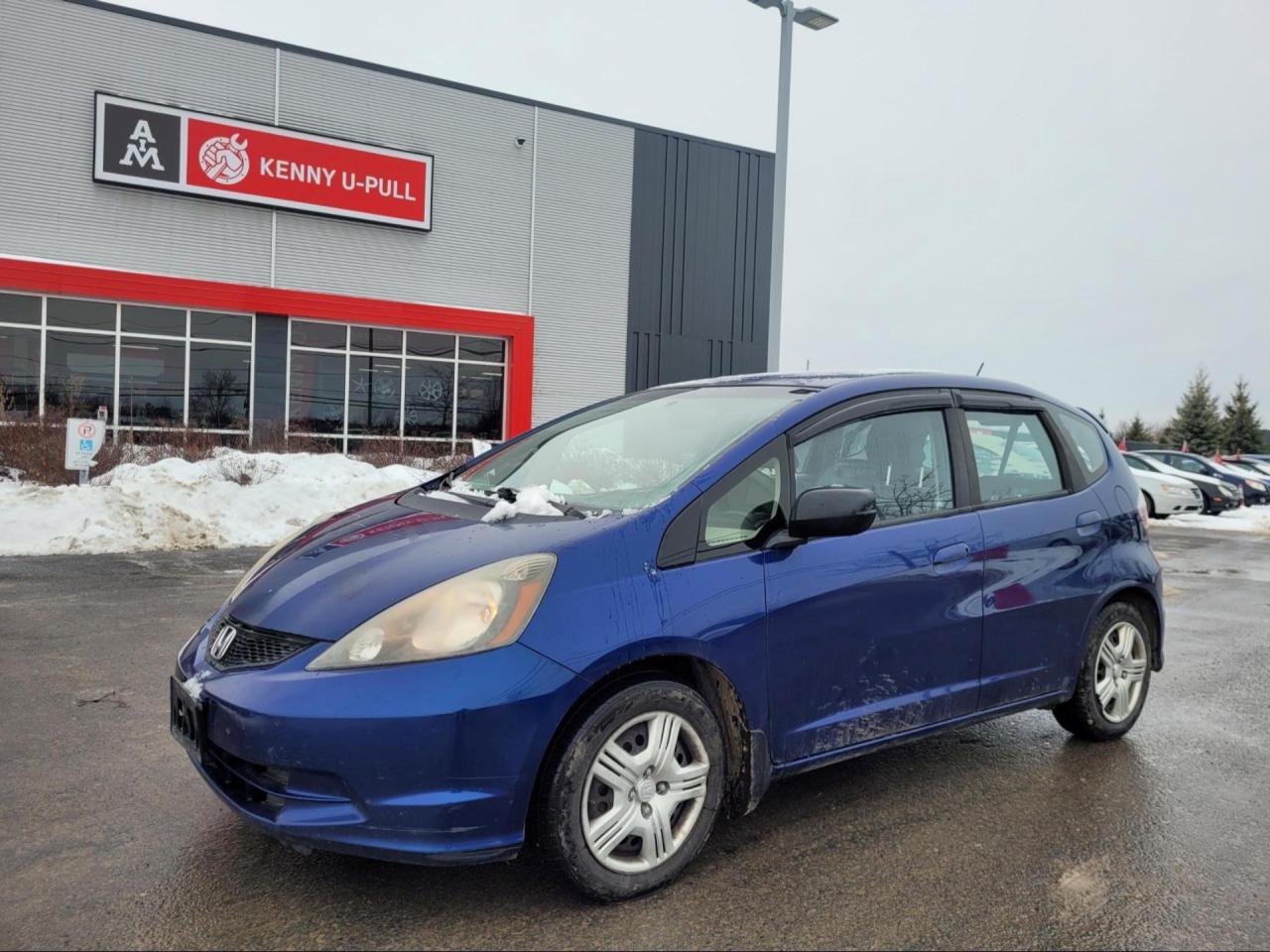 2014 Honda Fit in bright blue. The vehicle has 327,800km. Runs and drives ok. The body is in decent shape for the age. No check engine light. Slight vibrations felt in the cabin from the exhaust rattle. Theres an exhaust leak. We dont perform any mechanical/safety inspections. The vehicle is sold as is and might need some work.