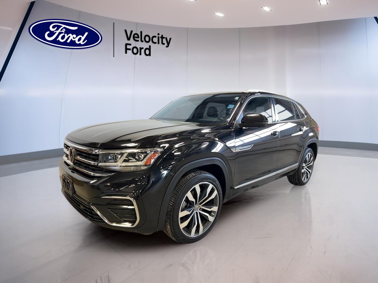 Discover the perfect blend of versatility, comfort, and technology with the 2023 Volkswagen Atlas Cross Sport Execline 3.6 FSI 4MOTION, now available at Velocity Ford in Moose Jaw. Finished in a classic black exterior, this used SUV has travelled 79,162 km and features an automatic 8-speed transmission paired with a robust 3.6-litre gas engine. Enjoy the confidence of all-wheel drive and a suite of premium features designed for Canadian drivers seeking style and substance.

FEATURES OF THE Atlas Cross Sport Execline 3.6 FSI 4MOTION  
»» Panoramic sunroof for expansive cabin light  
»» Memory seats and mirrors for personalized comfort  
»» Power liftgate for easy cargo access  
»» Dual-zone climate control for tailored comfort  

ADVANCED SAFETY FEATURES  
»» Blind spot monitor for safer lane changes  
»» Lane departure warning for added awareness  
»» Side impact and head side airbags for protection  
»» Child safety locks for family security  

PERFORMANCE AND EFFICIENCY  
»» 3.6-litre V6 engine for confident acceleration  
»» 4MOTION all-wheel drive for all-season capability  
»» Performance tires for enhanced road grip  
»» 8-speed automatic transmission with dual shift mode  

COMFORT AND CONVENIENCE  
»» Heated front and rear seats for chilly days  
»» Power adjustable driver and passenger seats  
»» Ambient lighting package for a refined interior  
»» Push button start and remote starter  

TECHNONOLGY AND CONNECTIVITY  
»» Navigation system (GPS) for easy route planning  
»» Bluetooth integration for hands-free calls  
»» WiFi hotspot for on-the-go connectivity  
»» HD radio and satellite radio for entertainment  

CARGO SPACE  
»» Power liftgate for effortless loading  
»» Cargo cover to keep belongings secure  
»» Rear trunk access for easy storage  
»» Spacious rear area for luggage and gear  

WHAT OTHER OWNERS LIKE  
»» Comfortable ride quality on long journeys  
»» User-friendly infotainment and navigation system  
»» Ample cargo space for family needs  
»» Strong all-wheel drive performance in all seasons  

This 2023 Volkswagen Atlas Cross Sport Execline 3.6 FSI 4MOTIONs VIN is: 1V2FE2CAXPC200130.