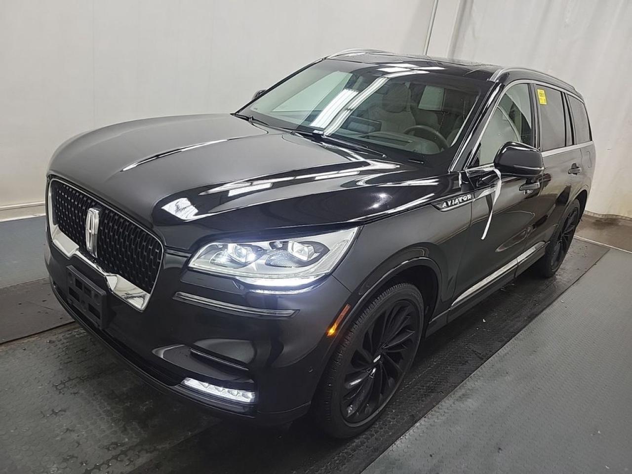 THE PRICE YOU SEE, PLUS GST. GUARANTEED!APPLE CARPLAY/ANDROID AUTO COMPATABLE! 3.0LITER TWIN TURBOCHARGED V6, 10 SPEED AUTO, RESERVE AWD TRIM(201a), SANDSTONE LEATHER SEATING, POWER/HEATED FRONT SEATS, HEATED REAR SEATS, PANORAMIC VISTA ROOF, ACTIVE PARK ASSIST 2.0, CLASS IV TRAILER TOW PKG, ILLUMINATION PKG, ADAPTIVE PIXEL LED HEADLAMPS, REVEL ULTIMATE AUDIO SYSTEM W 28 SPEAKERS, REAR DOOR SUNSHADES,  22 HIGH GLOSS EBONY WHEELS, MONOCHROMATIC PAINT, FULL REAR CONSOLE, SYNC 3.      The 2022 Lincoln Aviator Reserve AWD with the 3.0-liter twin-turbocharged V6 engine, 10-speed automatic transmission, Illumination Package, 20A Package, and Revel Ultimate 3D Audio System is a luxurious and technologically advanced midsize SUV that offers a premium driving experience. The 3.0-liter twin-turbo V6 provides powerful performance with impressive horsepower and torque, delivering smooth acceleration and confident highway cruising, while the all-wheel-drive system ensures excellent traction and handling in various driving conditions. The 10-speed automatic transmission enhances driving smoothness and efficiency, seamlessly shifting through gears for optimal performance. The Illumination Package adds ambient lighting accents throughout the cabin, creating a sophisticated and inviting interior atmosphere, while the 20A Package typically includes upgraded comfort and convenience features such as premium leather seats, heated and ventilated front seats, and advanced connectivity options, elevating the overall luxury feel. The Revel Ultimate 3D Audio System is a standout feature, delivering immersive sound quality with multiple strategically placed speakers and advanced acoustics, making every audio experience rich and spacious.Do you want to know more about this vehicle, CALL, CLICK OR COME ON IN!*AMVIC Licensed Dealer; CarFax and Full Mechanical Inspection Included.