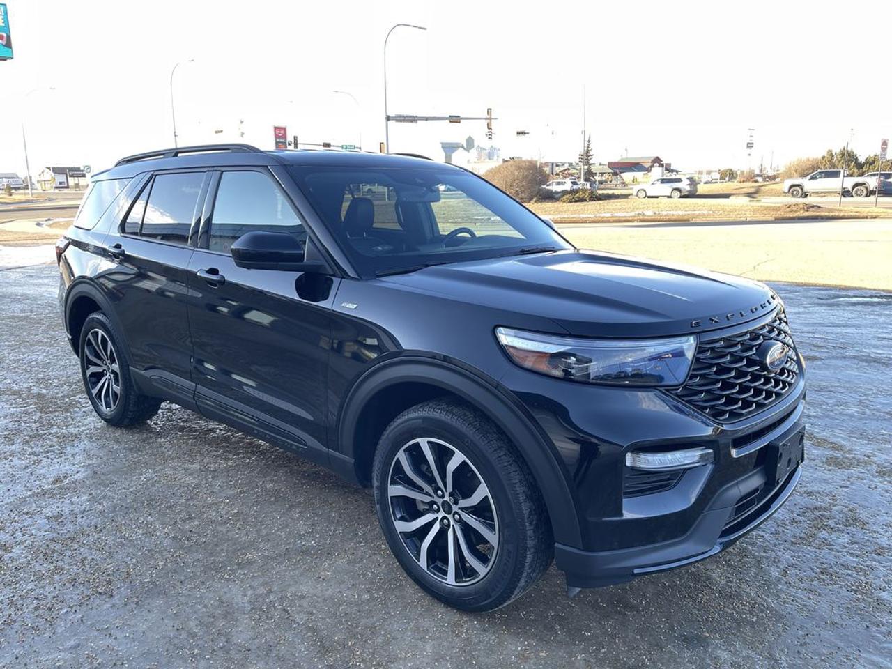 THE PRICE YOU SEE, PLUS GST. GUARANTEED!APPLE CARPLAY/ANDROID AUTO COMPATABLE! 2.3 LITER ECOBOOST, 10 SPEED AUTO, ST-LINE TRIM(250a), EBONY ACTIVE-X SEATS W RED STITCHING, POWER/HEATED FRONT SEATS, LEATHER WRAPPED STEERING WHEEL W/TILT/TELESCOPIC, ROOF SIDE RAILS, FORD PASS CONNECT, B&O AUDIO SYSTEM, AUTO START/STOP REMOVAL.        The 2022 Ford Explorer ST-Line with the 2.3-liter engine, 250A package, and auto start/stop removal is a sporty and well-equipped midsize SUV that combines performance, style, and practicality. The 2.3-liter turbocharged EcoBoost four-cylinder engine delivers spirited acceleration and a good balance of power and efficiency, making it suitable for both urban commuting and highway driving. The ST-Line trim enhances the vehicles sporty aesthetic with unique exterior styling cues, such as distinct grille designs, sporty wheels, and interior accents, giving it a more aggressive and dynamic look without the full performance upgrades of the ST model. The 250A package typically adds comfort, convenience, and technology features, including a larger touchscreen infotainment system with SYNC 3 or 4, smartphone integration, premium audio options, and additional driver-assistance features like blind-spot monitoring and adaptive cruise control. The removal of auto start/stop is a notable modification, often preferred by drivers who want to eliminate the engines automatic shutdown at idle for a smoother, more seamless driving experience and to avoid potential issues with the system. Overall, this Explorer ST-Line offers a compelling blend of sporty styling, modern technology, and reliable performance, tailored for drivers seeking an engaging yet practical family SUV with personalized features.Do you want to know more about this vehicle, CALL, CLICK OR COME ON IN!*AMVIC Licensed Dealer; CarFax and Full Mechanical Inspection Included.