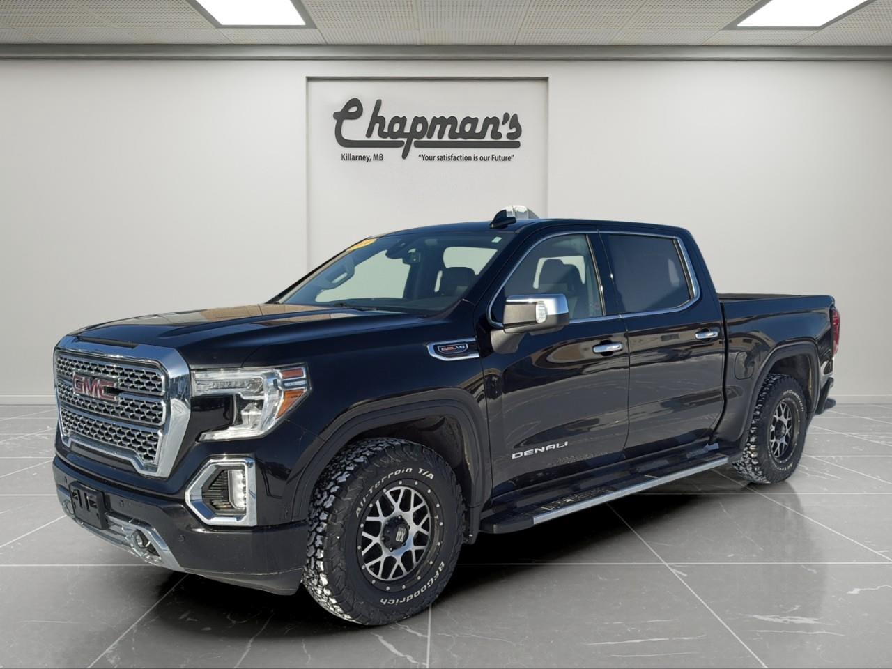 <p>The <strong>2019 GMC Sierra 1500 Denali</strong> is the perfect blend of brute strength and premium refinement. Finished in <strong>Onyx Black</strong> with a rich <strong>Jet Black leather interior</strong>, this Denali makes a bold statement while delivering a first-class driving experience.</p><p>Under the hood sits the legendary <strong>6.2L EcoTec3 V8</strong>, paired with a smooth and responsive <strong>10-speed automatic transmission</strong>. With <strong>Adaptive Ride Control</strong>, <strong>AutoTrac 4WD</strong>, and a full <strong>Advanced Trailering System</strong>, this Sierra delivers effortless power whether youre towing, cruising the highway, or tackling tough road conditions.</p><h3><strong>Performance & Capability</strong></h3><ul><li><p><strong>6.2L EcoTec3 V8 Engine</strong></p></li><li><p><strong>10-Speed Automatic Transmission</strong></p></li><li><p><strong>AutoTrac Two-Speed 4WD System</strong></p></li><li><p><strong>Automatic Locking Rear Differential</strong></p></li><li><p><strong>Adaptive Ride Control Suspension</strong></p></li><li><p><strong>Advanced Trailering System</strong></p></li><li><p><strong>Trailer Brake Controller</strong></p></li><li><p><strong>Hitch Guidance with Hitch View</strong></p></li><li><p><strong>High-Capacity Air Cleaner & Engine Block Heater</strong></p></li></ul><h3><strong>Denali Interior Luxury</strong></h3><p>Premium materials and comfort throughout:</p><ul><li><p><strong>Heated & Ventilated Front Leather Seats</strong></p></li><li><p><strong>Heated Rear Outboard Seats</strong></p></li><li><p><strong>10-Way Power Driver & Passenger Seats</strong></p></li><li><p><strong>Power Sliding Rear Window</strong></p></li><li><p><strong>Dual-Zone Automatic Climate Control</strong></p></li><li><p><strong>Heated Leather-Wrapped Steering Wheel</strong></p></li><li><p><strong>Rear Seat Storage Package</strong></p></li><li><p><strong>Wireless Phone Charging</strong></p></li><li><p><strong>120-Volt Power Outlet</strong></p></li></ul><h3><strong>Technology & Connectivity</strong></h3><p>A high-tech cockpit built around the driver:</p><ul><li><p><strong>Premium GMC Infotainment System with Navigation</strong></p></li><li><p><strong>Bose Premium Sound System</strong></p></li><li><p><strong>SiriusXM Radio</strong></p></li><li><p><strong>Wireless Charging</strong></p></li><li><p><strong>4G LTE Wi-Fi Hotspot</strong></p></li><li><p><strong>Multiple USB Ports Front & Rear</strong></p></li><li><p><strong>Universal Home Remote</strong></p></li></ul><h3><strong>Safety & Driver Assistance</strong></h3><p>Loaded with advanced driver-confidence features:</p><ul><li><p><strong>Forward Collision Alert & Low-Speed Automatic Braking</strong></p></li><li><p><strong>Lane Keep Assist & Lane Departure Warning</strong></p></li><li><p><strong>Lane Change Alert with Side Blind Zone Alert</strong></p></li><li><p><strong>Rear Cross-Traffic Alert</strong></p></li><li><p><strong>Front & Rear Park Assist</strong></p></li><li><p><strong>Driver Safety Alert Seat</strong></p></li><li><p><strong>IntelliBeam Automatic High Beams</strong></p></li></ul><h3><strong>Exterior Highlights</strong></h3><ul><li><p><strong>20" Polished Aluminum Wheels</strong></p></li><li><p><strong>GMC MultiPro Tailgate</strong></p></li><li><p><strong>Spray-On Bedliner</strong></p></li><li><p><strong>Chrome Assist Steps & Chrome Recovery Hooks</strong></p></li><li><p><strong>LED Cargo Bed Lighting</strong></p></li><li><p><strong>Front LED Fog Lamps</strong></p></li><li><p><strong>Deep-Tinted Rear Glass</strong></p></li></ul><h3><strong>Why Choose This Sierra Denali</strong></h3><p>With its <strong>6.2L V8</strong>, <strong>Denali luxury</strong>, <strong>adaptive ride control</strong>, <strong>advanced trailering technology</strong>, and <strong>premium Bose audio</strong>, this <strong>2019 Sierra 1500 Denali</strong> delivers everything you want in a full-size truck without compromise.</p><p>Price Includes Dealer Fee.</p><p>Price Excludes PST & GST.</p><p>Financing Options Available, Call For More Details.</p> <p><strong>*While every reasonable effort is made to ensure the accuracy of this information, we are not responsible for any error or omissions contained on these pages. Please verify any information in question with Chapman Motors Ltd.</strong></p>