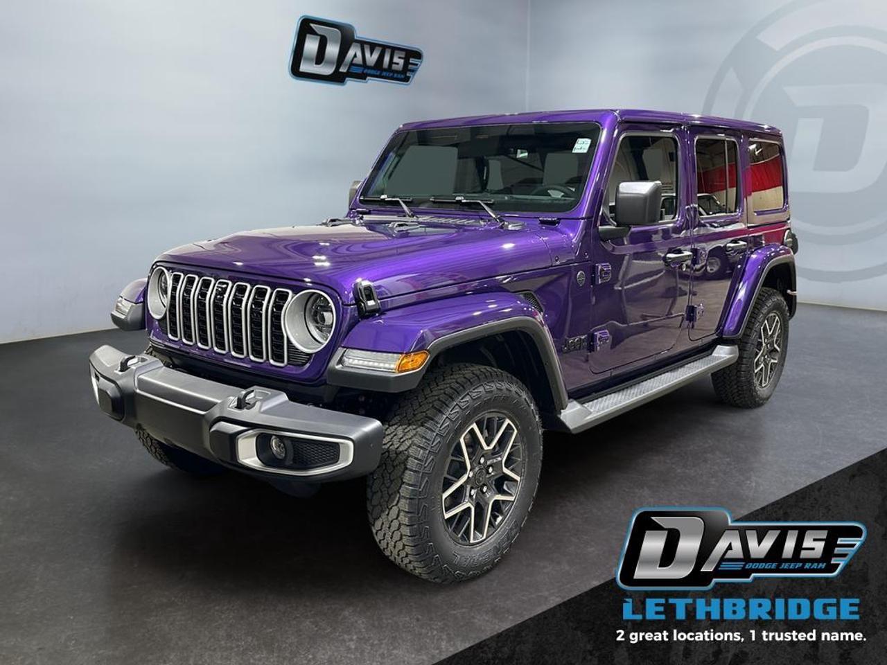 <b> Targa Sunroof, Alpine Audio, Heated Seats, Remote Start!<br /> <br /></b><br /> <br /> <br />The 2026 Jeep Wrangler Sahara 4x4 blends iconic Jeep design with everyday comfort and modern technology, making it a perfect SUV for drivers who want open-air freedom without sacrificing refinement. Finished in striking Reign, this four-door Wrangler features body-color fender flares and grille, neutral grey Sahara badging, matte black Jeep accents, LED lighting, side steps, and 18-inch aluminum wheels, giving it a bold yet upscale appearance.<br /><br />Powered by the proven 3.6L V6 engine with ESS and an 8-speed automatic transmission, the Wrangler Sahara delivers smooth performance on the road and confident capability off it. The Command-Trac® part-time 4WD system, Selec-Speed® control, skid plates, heavy-duty suspension, and trailer sway control ensure stability and traction in changing conditions, whether youre commuting, road-tripping, or exploring off the pavement.<br /><br />Inside, the Sahara offers a refined cabin with McKinley-trimmed seats, heated front seats, heated steering wheel, power-adjustable front seats with lumbar support, ambient LED interior lighting, and a body-color 3-piece hard top. Technology highlights include Uconnect 5 NAV with a 12.3-inch touchscreen, Apple CarPlay, Android Auto, Alpine premium audio, integrated off-road camera, and a 4G LTE Wi-Fi hotspot. Safety features such as adaptive cruise control with stop, blind-spot monitoring, ParkSense rear park assist, forward collision warning, and ParkView rear backup camera complete this well-equipped SUV. The 2026 Jeep Wrangler Sahara 4x4 delivers classic Jeep capability with a polished, modern edge.<br /> <br />To apply right now for financing use this link: <a href=https://lethbridge.davisdodge.ca/free-credit-check/ target=_blank rel=nofollow noopener noreferrer>https://lethbridge.davisdodge.ca/free-credit-check/</a><br /><br /> <br /><br />As a premier Chrysler, Dodge, Jeep and RAM dealership, Davis Dodge proudly offers an extensive selection of new and used vehicles to meet every drivers needs. Customers across Lethbridge, Fort Macleod, Taber, Claresholm, Coaldale, and beyond trust us for daily vehicle specials, certified service and parts, and a seamless online inventory experience. <br /><br /> With competitive financing options and expert support, we make car buying easy and enjoyable. <br /><br /> Ready to hit the road? Schedule your test drive today at Davis Dodge, your trusted Chrysler, Dodge, Jeep and RAM dealer in Lethbridge, Alberta.<br /><br /> Vehicle pricing offer shown expires 2026-04-30. <br /> Come by and check out our fleet of 70+ used cars and trucks and 110+ new cars and trucks for sale in Lethbridge. o~o