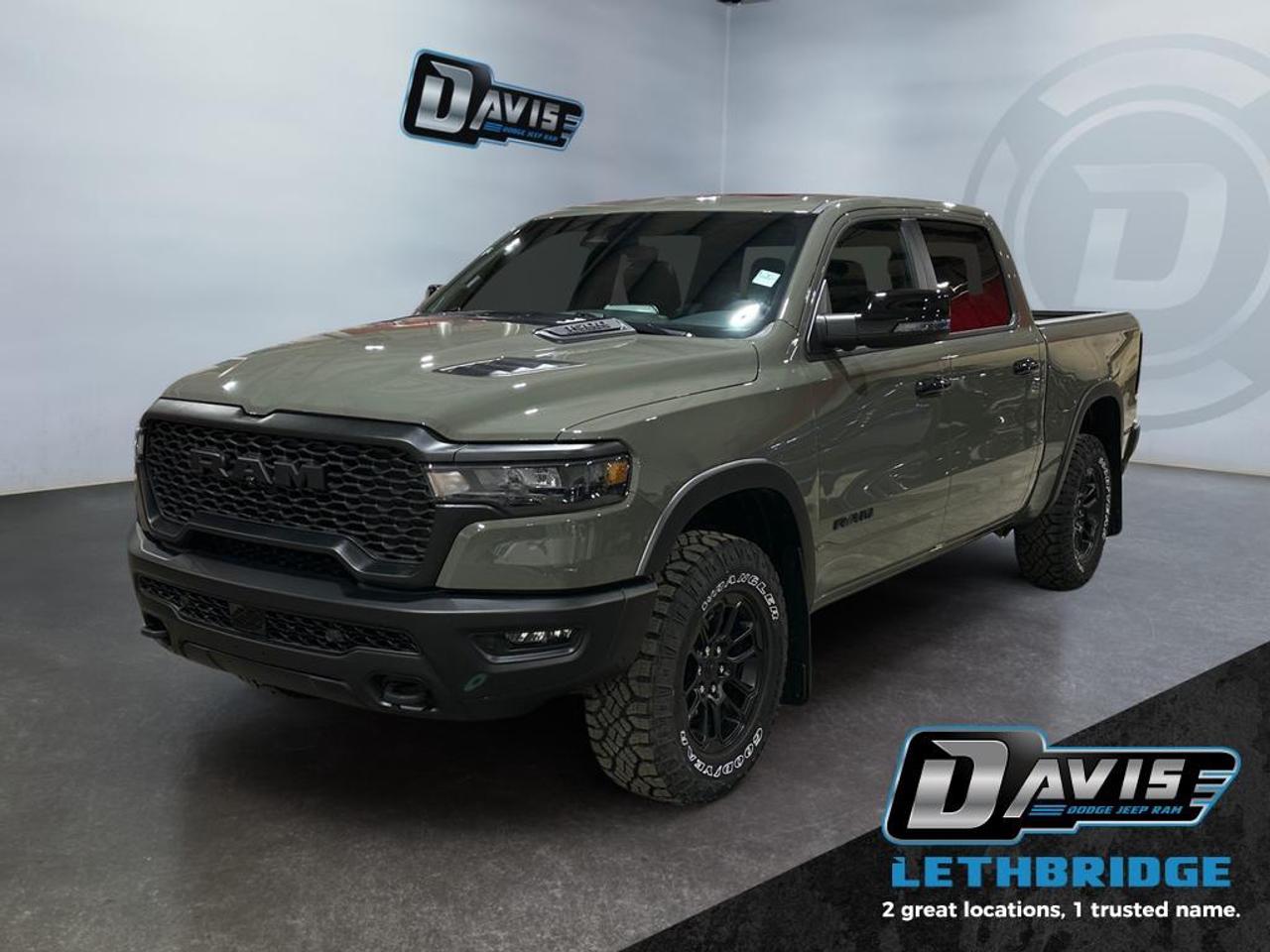 <b>Off-Road Suspension, Navigation, Apple CarPlay, Android Auto, 360 Camera!<br /> <br /></b><br /> <br /> <br />The 2026 Ram 1500 Rebel Crew Cab 4x4 is built for drivers who want aggressive off-road capability paired with premium comfort and cutting-edge technology. Finished in striking Canyon Lake, this Rebel stands out with blacked-out exterior badging, unique Rebel grille, black bumpers, off-road wheel flares, LED lighting, dual black exhaust tips, and 18-inch black aluminum wheels wrapped in all-terrain tires, giving it a bold, trail-ready stance.<br /><br />Under the hood is the powerful and efficient 3.0L Hurricane inline-6 twin-turbo engine, matched with an 8-speed automatic transmission and advanced four-wheel drive system. With a 3.92 rear axle, electronic locking rear differential, Selec-Speed control, raised ride height, skid plates, tow hooks, Class IV hitch, and performance-tuned off-road suspension, the Ram 1500 Rebel is engineered to handle rugged terrain, towing, and all-weather driving with confidence.<br /><br />Inside, the Rebel Level 2 package delivers upscale comfort and advanced tech, including leather-trimmed heated and ventilated bucket seats, heated steering wheel, power-adjustable front seats with memory, dual wireless charging, and a panoramic sunroof. The high-tech cabin features Uconnect 5 NAV with a massive 14.4-inch touchscreen, passenger interactive display, Harman Kardon 19-speaker premium audio, Apple CarPlay, Android Auto, and a surround-view camera system. Advanced safety features such as adaptive cruise control with stop and go, active driving assist, blind spot monitoring, lane management, intersection collision assist, and ParkSense front and rear park assist make the 2026 Ram 1500 Rebel 4x4 a perfect blend of off-road toughness, luxury, and everyday usability.<br /> <br />To apply right now for financing use this link: <a href=https://lethbridge.davisdodge.ca/free-credit-check/ target=_blank rel=nofollow noopener noreferrer>https://lethbridge.davisdodge.ca/free-credit-check/</a><br /><br /> <br /><br />As a premier Chrysler, Dodge, Jeep and RAM dealership, Davis Dodge proudly offers an extensive selection of new and used vehicles to meet every drivers needs. Customers across Lethbridge, Fort Macleod, Taber, Claresholm, Coaldale, and beyond trust us for daily vehicle specials, certified service and parts, and a seamless online inventory experience. <br /><br /> With competitive financing options and expert support, we make car buying easy and enjoyable. <br /><br /> Ready to hit the road? Schedule your test drive today at Davis Dodge, your trusted Chrysler, Dodge, Jeep and RAM dealer in Lethbridge, Alberta.<br /><br /> Vehicle pricing offer shown expires 2026-04-30. <br /> Come by and check out our fleet of 70+ used cars and trucks and 110+ new cars and trucks for sale in Lethbridge. o~o