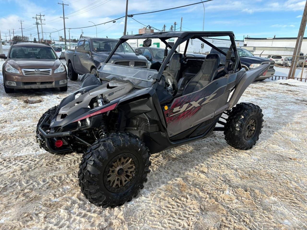 <p data-start=111 data-end=551>The 2024 Yamaha YXZ1000 SS is built for riders who want high-performance precision, agile handling, and responsive power for thrill-seeking trail and desert runs. Powered by a potent 998 cc naturally aspirated inline-three engine with Yamaha&rsquo;s unique sequential shift transmission, it delivers smooth throttle response, strong mid-range grunt, and engaging performance that&rsquo;s ready for anything from tight single-track to wide-open terrain.</p><p data-start=111 data-end=551>&nbsp;</p><p data-start=553 data-end=910>Purpose-built for sporty, responsive riding, the YXZ1000 SS features Yamaha&rsquo;s industry-leading handling package with premium long-travel suspension and FOX&dagger; shocks that absorb rough ground while maintaining control and confidence. Its sequential shift gearbox gives riders a more connected, manual-style experience with crisp, precise shifting at any speed.</p><p data-start=553 data-end=910>&nbsp;</p><p data-start=912 data-end=1269>Equipped with aggressive all-terrain tires on durable wheels, LED lighting, a digital instrument display, and a driver-focused cockpit, this side-by-side blends modern technology with rugged capability. Comfortable seating, thoughtful ergonomics, and ample storage make it ideal for performance-oriented trail riding, weekend adventures, or competitive fun.</p><p data-start=912 data-end=1269>&nbsp;</p><p data-start=1271 data-end=1356>Contact us today to learn more about financing, trade-ins, or delivery across Canada!</p>