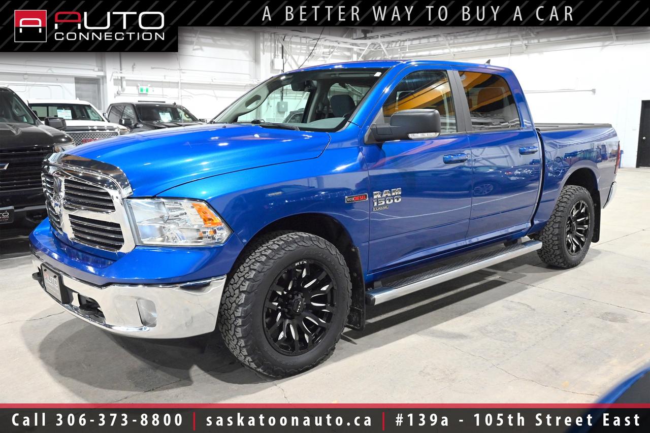 <p><span><font color=#000000><b>Financing & Warranty Available!</b><br></font></span><span><br></span><span><b>Crew Cab w/ 5.7ft. Box - SK Truck - 3.0L EcoDiesel V6</b><br></span><span><br>This <b>2019 RAM 1500 Classic SLT</b> Crew Cab, finished in striking Blue Streak Pearl, delivers the rugged capability and refined comfort that truck buyers expect from a proven full-size pickup. Powered by the efficient and torque-rich 3.0L EcoDiesel V6 paired with an 8-speed TorqueFlite automatic transmission, it offers confident performance whether commuting, towing, or heading off the beaten path. Its 4x4 drivetrain, skid plates, tow hooks, and electronic trailer brake controller make it a dependable choice for work and recreation alike. Inside, the Black and Diesel Grey premium cloth interior is thoughtfully designed, featuring a power-adjustable drivers seat, leather-wrapped steering wheel, and dual-zone automatic climate control for all-day comfort. The Uconnect 4C system with its large 8.4-inch touchscreen integrates seamlessly with Apple CarPlay and Android Auto, keeping navigation, calls, and media intuitive and accessible. A 7-inch in-cluster display and integrated voice command enhance driver awareness without distraction. Practical touches like remote start, a spray-in bedliner, LED bed lighting, and power-folding heated mirrors add real-world convenience. Sitting on bold 20-inch polished aluminum wheels and equipped with a large 98-litre fuel tank, this RAM 1500 Classic SLT is a versatile, confident truck ready for Saskatchewan roads, available now at Saskatoon Auto Connection.<br><br></span><span><b>Key Features:</b><br></span><span><br>- 4x4<br>- SLT Plus Decor Group<br>- Protection Group<br>- Remote Start & Security Alarm Group<br>- Apple CarPlay & Android Auto Compatibility<br>- Premium Cloth Front Bucket Seats w/ Full-Length Floor Console<br>- Leather-Wrapped Steering Wheel<br>- ParkView Rear Back-Up Camera<br>- Uconnect 4C w/ 8.4-Inch Display<br>- 7-Inch Colour In-Cluster Display<br>- Integrated Voice Command w/ Bluetooth Connectivity<br>- Dual-Zone Automatic Climate Control<br>- Power-Folding Heated Exterior Mirrors<br>- Auto-Dimming Rearview Mirror<br>- Universal Garage Door Opener<br>- 115V Auxiliary Power Outlet<br>- 10-Way Power-Adjustable Drivers Seat<br>- Fog Lamps<br>- LED Bed Lighting<br>- Spray-In Bedliner<br>- Tow Hooks<br></span><span>- 20-Inch Polished Aluminum Wheels<br></span><span>- Electronic Trailer Brake Controller</span><br><span>- Transfer Case & Front Suspension Skid Plates<br>- 98-Litre Fuel Tank<br>- 3.55 Rear Axle Ratio<br>- 8-Speed TorqueFlite Automatic Transmission<br>- 3.0L EcoDiesel 6-Cylinder Engine<br><br><b>Exterior Colour:</b> Blue Streak Pearl<br><b>Interior Colour:</b> Black/Diesel Grey Premium Cloth<br><br><b>OEM Window Sticker:</b> </span><a href=https://www.chrysler.com/hostd/windowsticker/getWindowStickerPdf.do?vin=1C6RR7LM0KS668237 target=_blank><span>https://www.chrysler.com/hostd/windowsticker/getWindowStickerPdf.do?vin=1C6RR7LM0KS668237</span></a><span><br><br></span><span>Unlock a full year of exclusive VIP benefits with your purchase! Enjoy 20% off labour, 25% off tires, free windshield stone chip repairs, and so much more. Visit saskatoonauto.ca for all the details.<br></span><span><br>Honesty Pricing eliminates the haggle hassle by providing you with our lowest possible selling price up front. In fact, it is the lowest price in our market, and we will prove it by disclosing a comprehensive market report of what our competitors are selling similar vehicles for.<br></span><span><br>This vehicle meets our Diamond Certification standard, which begins by selecting only premium quality vehicles and subjecting them to a much more comprehensive inspection process than typical dealerships use. Diamond Certified ensures a clean history, exceptional appearance and problem-free operation.<br></span><span><br>At Saskatoon Auto Connection we sell pre-owned automobiles the way we would like to buy them ourselves. Since 2008, we have been dedicated to providing the highest level of integrity and transparency in our industry, in combination with the highest quality vehicles at the most competitive prices in Saskatchewan. Our friendly staff is ready to positively redefine your expectations of the pre-owned automobile space.</span><span></span></p>