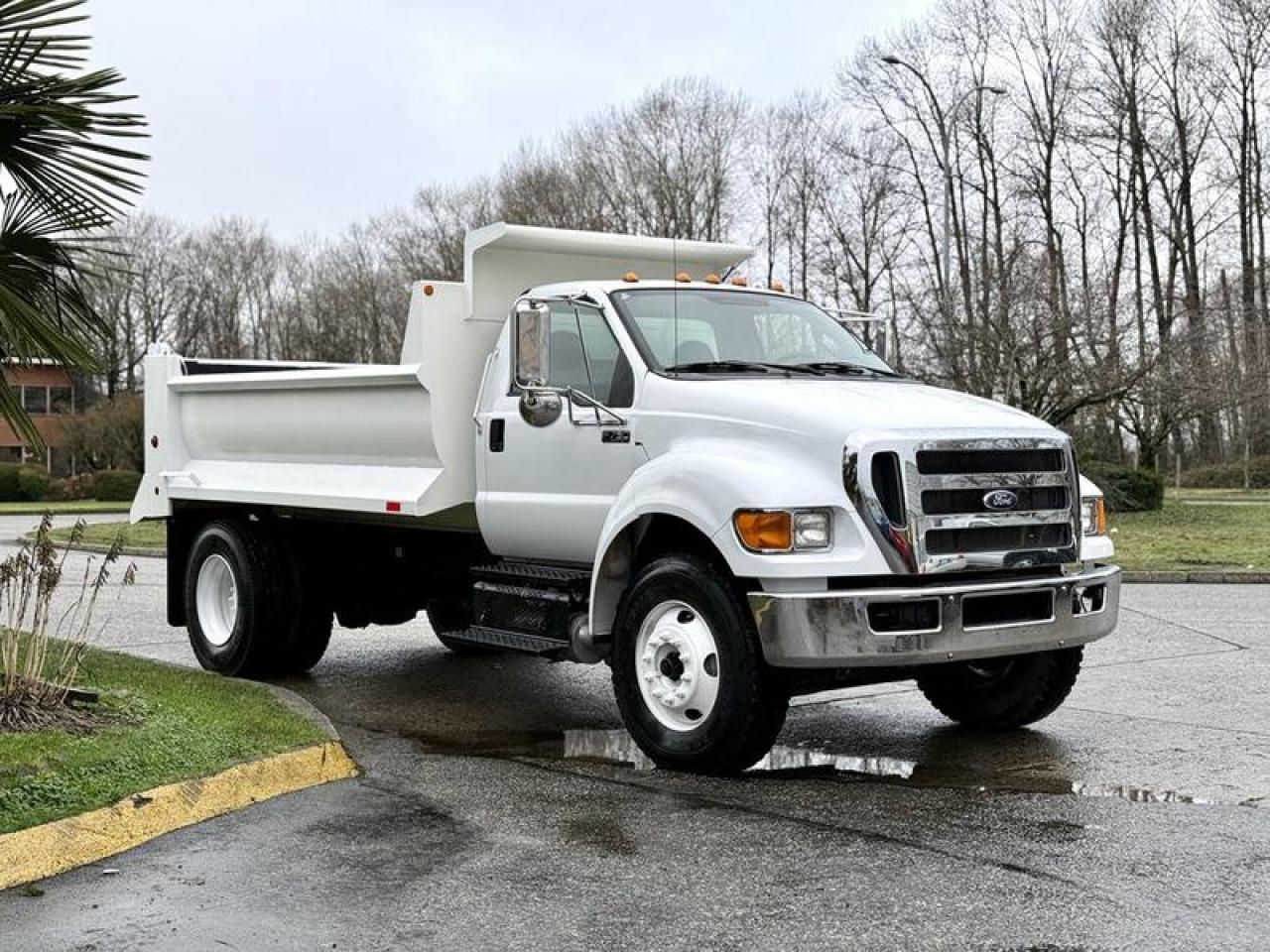 Used 2011 Ford F-750 XL Super Duty Cummins 12-Foot Dump Truck with Air Brakes for sale in Burnaby, BC