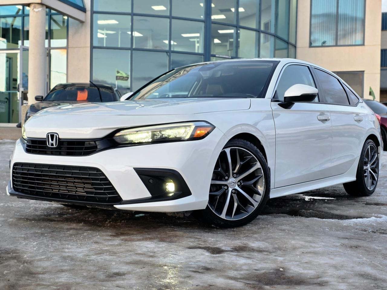 1.5L 4 CYLINDER ENGINE, LEATHER, NAVIGATION, DIGITAL CLUSTER, BOSE AUDIO, SUNROOF, REMOTE STARTER, KEYLESS ENTRY, HEATED SEATS, ADAPTIVE CRUISE, LANE ASSIST, APPLE CARPLAY, ANDROID AUTO, BACKUP CAMERA, PUSH START, POWER SEATS, AND MUCH MORE! <br/> <br/> <br/> Now Available: 2023 Honda Civic Touring White has 160,053 KM on it. 1.5L 4 Cylinder Engine engine, Front-Wheel Drive, CVT transmission, 5 Seater passengers, on special price for $24,900.00. <br/> <br/> <br/> Book your appointment today for Test Drive. We offer contactless Test drives & Virtual Walkarounds. Stock Number: 25343 <br/> Disclosure: This vehicle was previously registered in BC. Vehicle has passed all required inspections in Alberta. <br/> At Diamond Motors, we are dedicated to providing you with an outstanding car-buying experience, offering quality pre-owned vehicles at prices that fit your budget. Our transparent and honest approach means you can expect straightforward guidance without any high-pressure sales tactics. We believe in building lasting relationships with our customers by offering personalized service tailored to your needs. From the moment you step onto our lot, our team is here to support you every step of the way, ensuring you leave confident in your decision. Trust, integrity, and customer satisfaction are the foundation of everything we do. <br/> <br/> <br/> Why Choose Diamond Motors?<br/> <br/> Certified Pre-Owned Vehicles <br/> Family Owned & Operated <br/> 100+ Vehicles in Stock <br/> Finance & Extended Warranty Available <br/> Transparent Pricing <br/> Inspection & Carfax Provided <br/> No-Pressure Buying Experience <br/> Full Disclosure Guaranteed <br/> Top Google Rated Dealership <br/> Trade-Ins Welcome <br/> AMVIC Licensed & BBB Accredited <br/> CarGurus Top-Rated Dealer (2022 & 2024) <br/> <br/> <br/> Phone to schedule an appointment @ 587-444-3300 or simply browse our inventory online www.diamondmotors.ca or come and see us at our location at <br/> 3403 93 street NW, Edmonton, T6E 6A4 <br/> <br/> <br/> To view the rest of our inventory: <br/> www.diamondmotors.ca/inventory <br/> <br/> <br/> This dealership provides all required disclosures in accordance with AMVIC regulations. A completed Mechanical Fitness Assessment and its associated inspection work order will be supplied with every vehicle. A Carfax (or equivalent) vehicle history report will also be provided, including available information on previous damage, accident history, stolen or salvage status, and jurisdictional records. <br/> Customers are encouraged to review all vehicle features, options, and equipment for accuracy prior to purchase. <br/>