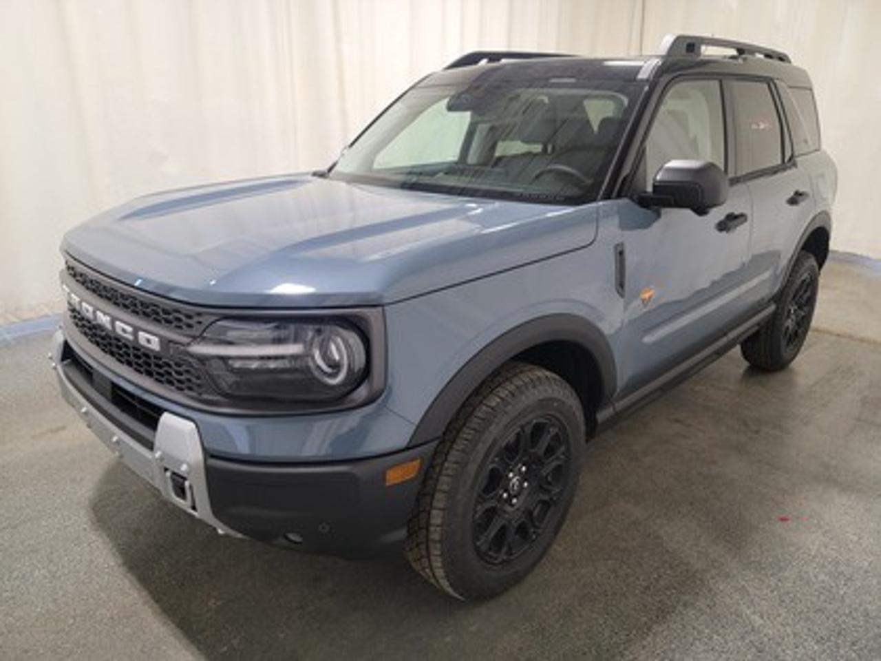 This all-new 2026 Ford Bronco Sport Badlands 400A stands out in Azure Grey Metallic, showcasing a rugged yet refined look. This 5-passenger SUV is equipped with the 2.0L EcoBoost® engine, producing 250 horsepower and 277 lb-ft of torque. Paired with an 8-speed automatic transmission, this vehicle ensures seamless power delivery both on and off the road, it is engineered to conquer tough terrains with ease.

This vehicle comes with the All-Weather Packageready to take on any season!
Snow, rain, mud, or sunshinethis vehicle is built for it all! The All-Weather Package adds extra protection where it matters most, with premium mud flaps to shield your paint from road debris, all-weather floor mats to protect your interior from lifes messes, and Xpel paint protection to help guard against those infuriating rock chips. Drive with confidence, knowing your investment is protected from Regina's elements.

Key Features:
Advanced 4x4 with Terrain Management System and 7 G.O.A.T. Modes
Leather-Trimmed Sport Heated Front Seats
Heated Premium-Wrapped Steering Wheel
Rubberized Floor and Cargo Area for Easy Cleaning
HOSS 2.0 Off-Road Suspension
17 Matte Black-Painted Aluminum Wheels with All-Terrain Tires
Class II Trailer Tow Package with Trailer Sway Control
Ford Co-Pilot360 Assist 2.0, including:
360-Degree Camera with Trail View
Reverse Brake Assist
Front Parking Sensors
12.3 Digital Instrument Panel Cluster
SYNC® 4 with a 13.2 Center Display, featuring Wireless Apple CarPlay® and Android Auto
Trail Control with One-Pedal Driving
Power Moonroof
Badlands Tech Package

Bennett Dunlop Ford, proudly serving Regina for over 40 years, is conveniently located at 770 Broad Street. With over 3,500 Google reviews, our reputation reflects our commitment to providing a fast, easy, and enjoyable vehicle-buying experience. We eliminate the hassle with no admin or documentation fees, transparent upfront pricing that lets you shop with total confidence. But were more than just a dealershipwere driven to make a difference by supporting local community initiatives and events that matter to you. Visit Bennett Dunlop Ford today and experience why were Reginas trusted choice for quality vehicles, exceptional service, and a genuine commitment to driving change in our community!