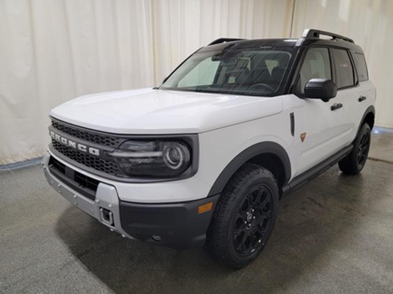 This all-new 2026 Ford Bronco Sport Badlands 400A stands out in Oxford White, showcasing a rugged yet refined look. This 5-passenger SUV is equipped with the 2.0L EcoBoost® engine, producing 250 horsepower and 277 lb-ft of torque. Paired with an 8-speed automatic transmission, this vehicle ensures seamless power delivery both on and off the road, it is engineered to conquer tough terrains with ease.

This vehicle comes with the All-Weather Packageready to take on any season!
Snow, rain, mud, or sunshinethis vehicle is built for it all! The All-Weather Package adds extra protection where it matters most, with premium mud flaps to shield your paint from road debris, all-weather floor mats to protect your interior from lifes messes, and Xpel paint protection to help guard against those infuriating rock chips. Drive with confidence, knowing your investment is protected from Regina's elements.

Key Features:
Advanced 4x4 with Terrain Management System and 7 G.O.A.T. Modes
Leather-Trimmed Sport Heated Front Seats
Heated Premium-Wrapped Steering Wheel
Rubberized Floor and Cargo Area for Easy Cleaning
HOSS 2.0 Off-Road Suspension
17 Matte Black-Painted Aluminum Wheels with All-Terrain Tires
Class II Trailer Tow Package with Trailer Sway Control
Ford Co-Pilot360 Assist 2.0, including:
360-Degree Camera with Trail View
Reverse Brake Assist
Front Parking Sensors
12.3 Digital Instrument Panel Cluster
SYNC® 4 with a 13.2 Center Display, featuring Wireless Apple CarPlay® and Android Auto
Trail Control with One-Pedal Driving
Badlands Tech Package
Power Moonroof

Bennett Dunlop Ford, proudly serving Regina for over 40 years, is conveniently located at 770 Broad Street. With over 3,500 Google reviews, our reputation reflects our commitment to providing a fast, easy, and enjoyable vehicle-buying experience. We eliminate the hassle with no admin or documentation fees, transparent upfront pricing that lets you shop with total confidence. But were more than just a dealershipwere driven to make a difference by supporting local community initiatives and events that matter to you. Visit Bennett Dunlop Ford today and experience why were Reginas trusted choice for quality vehicles, exceptional service, and a genuine commitment to driving change in our community!