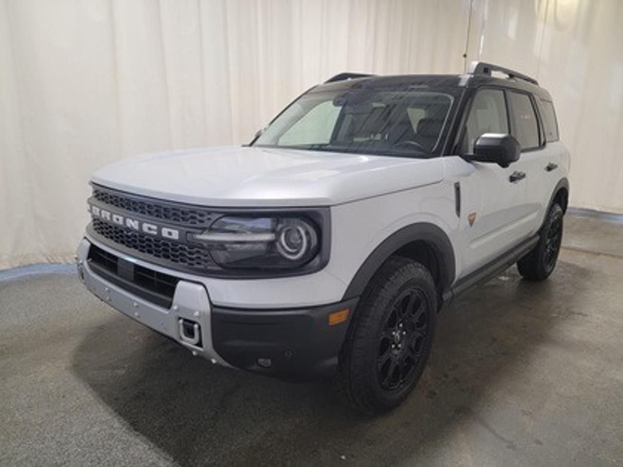 This all-new 2026 Ford Bronco Sport Badlands 400A stands out in Star White Metallic, showcasing a rugged yet refined look. This 5-passenger SUV is equipped with the 2.0L EcoBoost® engine, producing 250 horsepower and 277 lb-ft of torque. Paired with an 8-speed automatic transmission, this vehicle ensures seamless power delivery both on and off the road, it is engineered to conquer tough terrains with ease.

This vehicle comes with the All-Weather Packageready to take on any season!
Snow, rain, mud, or sunshinethis vehicle is built for it all! The All-Weather Package adds extra protection where it matters most, with premium mud flaps to shield your paint from road debris, all-weather floor mats to protect your interior from lifes messes, and Xpel paint protection to help guard against those infuriating rock chips. Drive with confidence, knowing your investment is protected from Regina's elements.

Key Features:
Advanced 4x4 with Terrain Management System and 7 G.O.A.T. Modes
Leather-Trimmed Sport Heated Front Seats
Heated Premium-Wrapped Steering Wheel
Rubberized Floor and Cargo Area for Easy Cleaning
HOSS 2.0 Off-Road Suspension
17 Matte Black-Painted Aluminum Wheels with All-Terrain Tires
Class II Trailer Tow Package with Trailer Sway Control
Ford Co-Pilot360 Assist 2.0, including:
360-Degree Camera with Trail View
Reverse Brake Assist
Front Parking Sensors
12.3 Digital Instrument Panel Cluster
SYNC® 4 with a 13.2 Center Display, featuring Wireless Apple CarPlay® and Android Auto
Trail Control with One-Pedal Driving
Power Moonroof
Badlands Tech Package

Designed for adventure, the Badlands 400A delivers confidence in harsh weather and challenging landscapes. Features like D-ring recovery hooks, and a 110V/400W AC power outlet ensure you're equipped for any situation. Its tech-forward interior includes dual-zone automatic climate control and universal garage door opener, under seat storage compartment and even a bottle opener for ultimate convenience.

Bennett Dunlop Ford, proudly serving Regina for over 40 years, is conveniently located at 770 Broad Street. With over 3,500 Google reviews, our reputation reflects our commitment to providing a fast, easy, and enjoyable vehicle-buying experience. We eliminate the hassle with no admin or documentation fees, transparent upfront pricing that lets you shop with total confidence. But were more than just a dealershipwere driven to make a difference by supporting local community initiatives and events that matter to you. Visit Bennett Dunlop Ford today and experience why were Reginas trusted choice for quality vehicles, exceptional service, and a genuine commitment to driving change in our community!