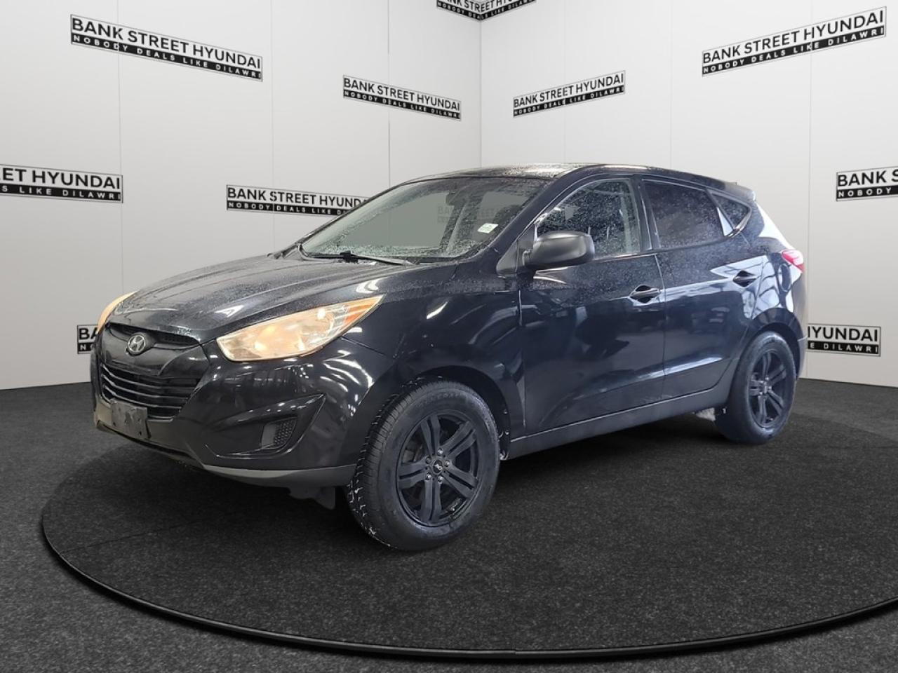 Experience the perfect blend of style and functionality with the 2013 Hyundai Tucson GL, featuring a sleek black exterior that complements its efficient front-wheel drive system. The automatic transmission provides a smooth and responsive handling experience, making it the ideal companion for both city drives and highway adventures. Step inside to find a thoughtfully designed interior where convenience meets comfort. The Tucsons cabin is equipped with ample features like heated mirrors and heated front seats for those chilly Canadian winters. Its air conditioning keeps the interior pleasant year-round, while the artificial leather centre console offers both storage and a touch of sophistication. Stay connected and secure with the Tucsons advanced technology package, including a Bluetooth connection for hands-free communication, and keyless entry which emphasizes convenience and safety. Features like brake assist and power windows add to the ease of driving this versatile SUV. Not to mention, cruise control to maintain your speed efficiently during long road trips. This 2013 Hyundai Tucson GL is the perfect match for families, adventurers, or anyone looking for a reliable vehicle with a robust set of features. Contact us today to learn more and schedule a test drive. Dont miss the chance to make it yours!