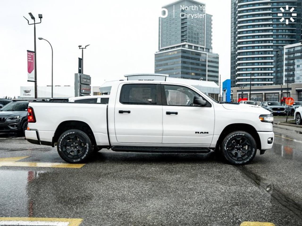 2026 RAM 1500 Express 4x4 Crew Cab 5'7" Box Black Express Edition Tonneau Cover Side Steps Photo