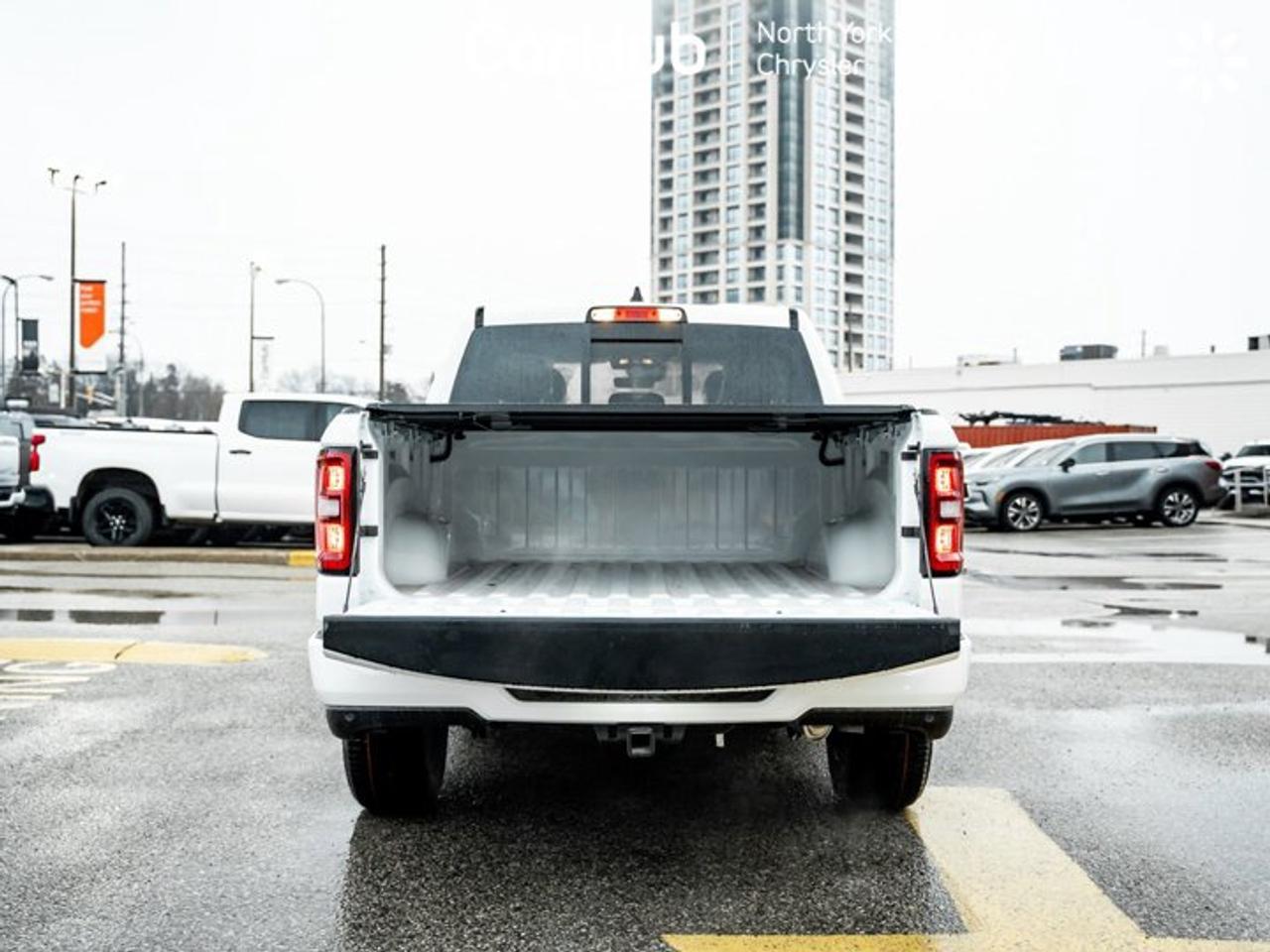 2026 RAM 1500 Express 4x4 Crew Cab 5'7" Box Black Express Edition Tonneau Cover Side Steps Photo