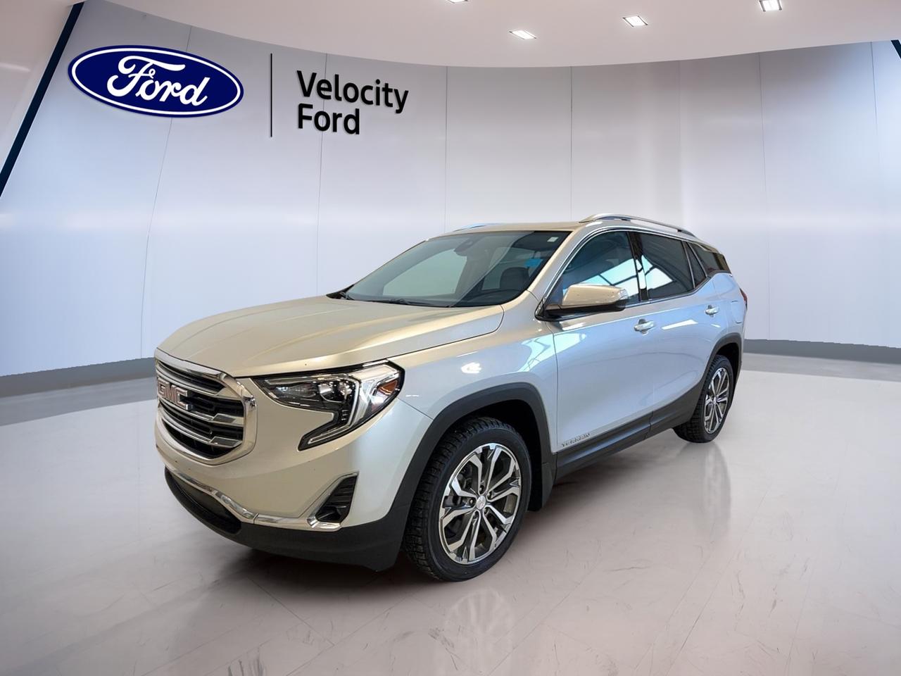 Meet the 2018 GMC Terrain SLT AWD, now available at Velocity Ford in Moose Jaw. Finished in grey with 4 doors, this used SUV is a smart pick for drivers who want confident all-weather traction and a well-equipped cabin. With 171,241 km, it is ready for daily commuting, weekend errands, and highway trips with ease.

Under the hood, the 2018 GMC Terrain SLT AWD features a 2.0 L gas engine paired with an automatic transmission. This combination delivers smooth power for merging and passing, while the dual shift mode transmission gives you more control when you want it. Add in modern convenience features, and you have an SUV that fits busy Saskatchewan life.

FEATURES OF THE Terrain SLT AWD
»» All-wheel drive for confident traction  
»» 2.0 L gas engine power  
»» Automatic transmission with dual shift  
»» Power liftgate for easy loading  

ADVANCED SAFETY FEATURES
»» Anti-lock braking system helps maintain control  
»» Stability control supports confident handling  
»» Side impact airbags for added protection  
»» Backup camera aids safe reversing  

PERFORMANCE AND EFFICIENCY
»» 2.0 L gas engine for strong response  
»» Automatic transmission for smooth operation  
»» Dual shift mode for added driver control  
»» All-wheel drive for varied road conditions  

COMFORT AND CONVENIENCE
»» Dual-zone automatic climate control comfort  
»» Heated front seats for cold days  
»» Remote starter for quick warm-ups  
»» Power windows for easy daily use  

TECHNONOLGY AND CONNECTIVITY
»» Bluetooth integration for hands-free calling  
»» Steering wheel audio controls included  
»» Satellite radio for more listening choice  
»» WiFi hotspot helps keep you connected  

CARGO SPACE
»» Power liftgate simplifies loading groceries  
»» Rear trunk access for quick entry  
»» Remote trunk release adds convenience  
»» Spare tire included for peace of mind  

WHAT OTHER OWNERS LIKE
»» Confident feel from all-wheel drive  
»» Easy parking with backup camera  
»» Heated seats and remote start convenience  
»» Simple Bluetooth and audio controls  

The 2018 GMC Terrain SLT AWD also adds practical exterior touches like fog lights, HID headlights, automatic headlights, tinted windows, and heated mirrors with turn signals. Inside, you will appreciate helpful details such as an auto-dimming rearview mirror, power outlet, automatic door locks, and a rear window defroster for winter visibility.

This 2018 GMC Terrain SLT AWDs VIN is: 3GKALVEX0JL221475.