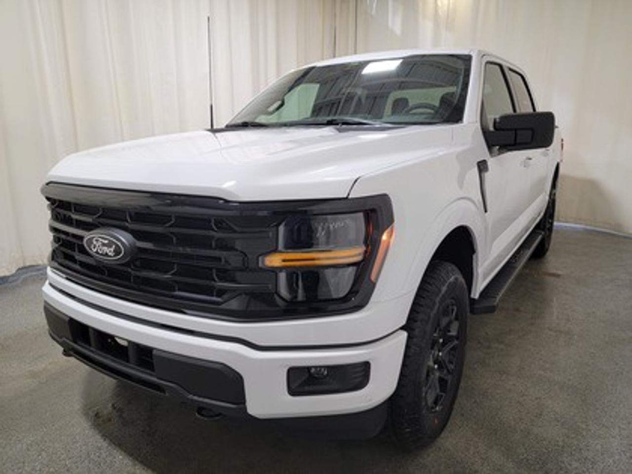 This all-new, full-sized 2026 Ford F-150 XLT  301A is a showstopper in Oxford White. This pickup is equipped with the 5L V8 engine, producing 395 horsepower and 400 lb-ft of torque. Paired with a 10-speed automatic transmission, this truck achieves a combined fuel economy of 12.8L/100km (22 miles per gallon), making it both powerful and efficient. 

This vehicle comes with the All-Weather Packageready to take on any season!
Snow, rain, mud, or sunshinethis vehicle is built for it all! The All-Weather Package adds extra protection where it matters most, with premium mud flaps to shield your paint from road debris, all-weather floor mats to protect your interior from lifes messes, and Xpel paint protection to help guard against those infuriating rock chips. Drive with confidence, knowing your investment is protected from Regina's elements.

Key Features:
12 LCD Captivity Touchscreen
Electronic Power-Assist Steering
Dual-Zone Electronic Auto Temp Control
Cruise Control
Power Windows
AdvanceTrac® With Roll Stability Control
Perimeter Alarm
Ford Co-Pilot360
Lane Keeping System
Rear View Camera
Rear Parking Sensors
Reverse Park Assist
Class IV Trailer Hitch
Power Drivers Seat
Remote Start
SYNC®4
Apple Car Play
18 All Terrain Tires
Bluetooth Connectivity
Electronic Locking Axle
Black Appearance Package
FX4 Off-Road Package

From navigating Saskatchewan's rugged terrain to hauling gear for your next project, the 2026 Ford F-150 XLT combines capability, technology, and comfort into a trusted workhorse that adapts to your needs. Engineered for durability, the F-150 XLT offers heavy-duty shock absorbers, rear privacy glass, interior worksurface, dual exhaust tips, LED reflector headlamps. Inside, enjoy smart features like power windows, tilt/telescoping steering wheel, and USB charging ports for added convenience. Safety remains a priority with Post Collision Braking, Dynamic Brake Support, and advanced airbag systems.

Bennett Dunlop Ford, proudly serving Regina for over 40 years, is conveniently located at 770 Broad Street. With over 3,500 Google reviews, our reputation reflects our commitment to providing a fast, easy, and enjoyable vehicle-buying experience. We eliminate the hassle with no admin or documentation fees, transparent upfront pricing that lets you shop with total confidence. But were more than just a dealershipwere driven to make a difference by supporting local community initiatives and events that matter to you. Visit Bennett Dunlop Ford today and experience why were Reginas trusted choice for quality vehicles, exceptional service, and a genuine commitment to driving change in our community!