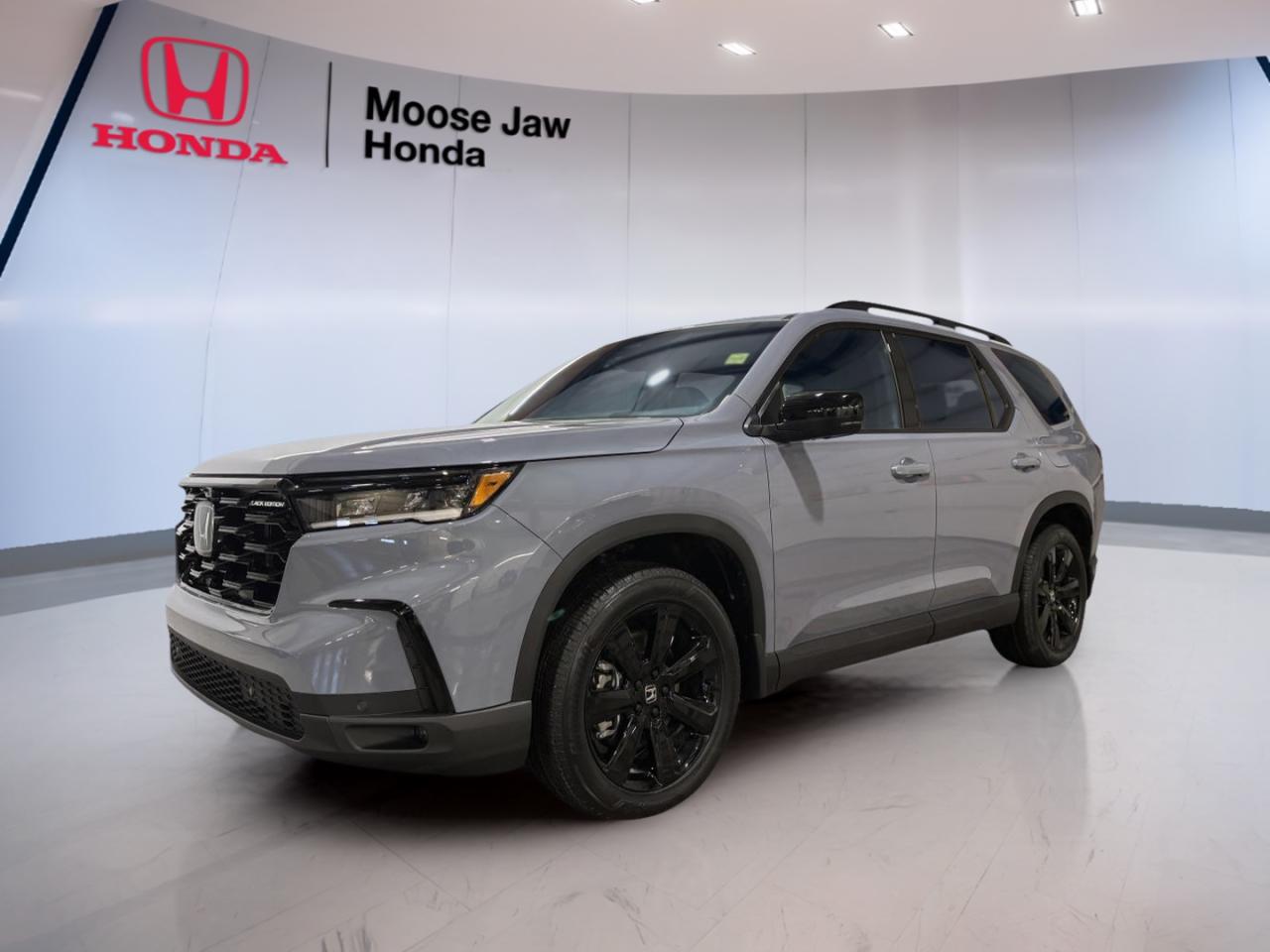 Experience the bold presence and advanced engineering of the brand new 2025 Honda Pilot Black Edition, now available at Moose Jaw Honda in Moose Jaw. This all-wheel drive SUV stands out with its grey exterior and black interior, offering a refined look combined with robust capability. The 2025 Pilot Black Edition is designed for families and adventurers alike, blending power, technology, and comfort in every journey.

FEATURES OF THE Pilot Black Edition  
»» Exclusive blacked-out exterior accents and trim  
»» Distinctive 20-inch black alloy wheels  
»» Panoramic roof for an open-air feel  
»» Red ambient interior lighting for added style  

ADVANCED SAFETY FEATURES  
»» Advanced stability control for confident handling  
»» Collision mitigation braking system  
»» Adaptive cruise control for highway ease  
»» Lane keeping assist for safer driving  

PERFORMANCE AND EFFICIENCY  
»» 3.5L V6 engine with Dual VTC technology  
»» Idle-stop system for improved fuel efficiency  
»» 10-speed automatic transmission with shift-by-wire  
»» All-wheel drive system for enhanced traction  

COMFORT AND CONVENIENCE  
»» Spacious three-row seating for eight passengers  
»» Tri-zone automatic climate control  
»» Power tailgate for easy cargo access  
»» Heated steering wheel for cold mornings  

TECHNONOLGY AND CONNECTIVITY  
»» Large touchscreen infotainment display  
»» Apple CarPlay and Android Auto integration  
»» Wireless charging pad for compatible devices  
»» Multiple USB charging ports throughout cabin  

CARGO SPACE  
»» Generous rear cargo area for gear and luggage  
»» Flat-folding second and third row seats  
»» Underfloor storage compartment for valuables  
»» Easy-load height for convenient access  

WHAT OTHER OWNERS LIKE  
»» Confident all-weather all-wheel drive system  
»» Smooth and quiet V6 engine performance  
»» User-friendly infotainment and connectivity features  
»» Comfortable ride for families and long trips  

This 2025 Honda Pilot Black Editions VIN is: 5FNYG1H97SB513385.<p>Experience the bold presence and advanced engineering of the brand new 2025 Honda Pilot Black Edition</p>
<p> now available at Moose Jaw Honda in Moose Jaw. This all-wheel drive SUV stands out with its grey exterior and black interior</p>
<p> offering a refined look combined with robust capability. The 2025 Pilot Black Edition is designed for families and adventurers alike</p>
<p> and comfort in every journey.

FEATURES OF THE Pilot Black Edition  
»» Exclusive blacked-out exterior accents and trim  
»» Distinctive 20-inch black alloy wheels  
»» Panoramic roof for an open-air feel  
»» Red ambient interior lighting for added style  

ADVANCED SAFETY FEATURES  
»» Advanced stability control for confident handling  
»» Collision mitigation braking system  
»» Adaptive cruise control for highway ease  
»» Lane keeping assist for safer driving  

PERFORMANCE AND EFFICIENCY  
»» 3.5L V6 engine with Dual VTC technology  
»» Idle-stop system for improved fuel efficiency  
»» 10-speed automatic transmission with shift-by-wire  
»» All-wheel drive system for enhanced traction  

COMFORT AND CONVENIENCE  
»» Spacious three-row seating for eight passengers  
»» Tri-zone automatic climate control  
»» Power tailgate for easy cargo access  
»» Heated steering wheel for cold mornings  

TECHNONOLGY AND CONNECTIVITY  
»» Large touchscreen infotainment display  
»» Apple CarPlay and Android Auto integration  
»» Wireless charging pad for compatible devices  
»» Multiple USB charging ports throughout cabin  

CARGO SPACE  
»» Generous rear cargo area for gear and luggage  
»» Flat-folding second and third row seats  
»» Underfloor storage compartment for valuables  
»» Easy-load height for convenient access  

WHAT OTHER OWNERS LIKE  
»» Confident all-weather all-wheel drive system  
»» Smooth and quiet V6 engine performance  
»» User-friendly infotainment and connectivity features  
»» Comfortable ride for families and long trips  

This 2025 Honda Pilot Black Editions VIN is: 5FNYG1H97SB513385.</p>