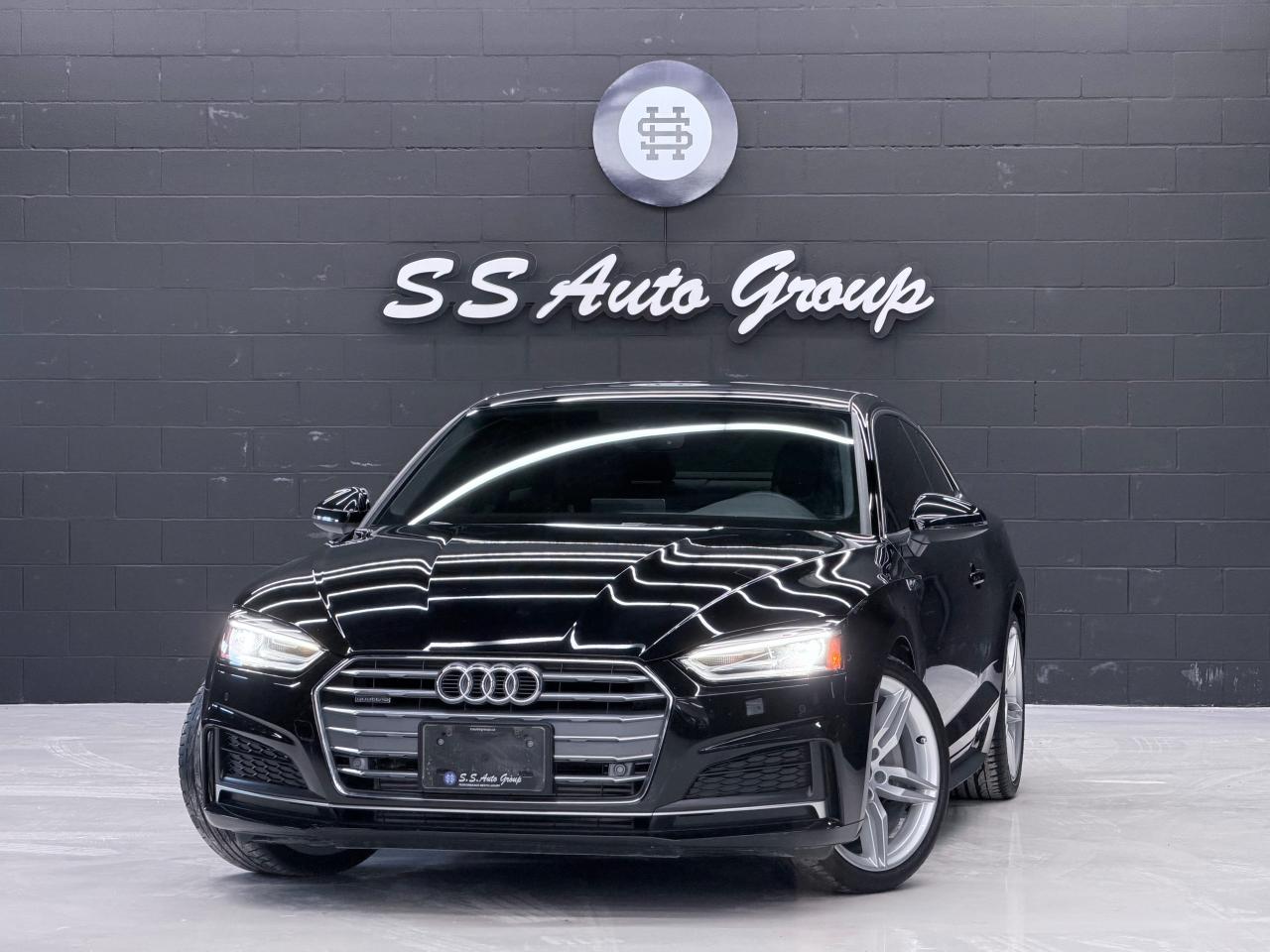 <p class=MsoNormal><span style=font-size: 9.0pt; line-height: 107%; mso-bidi-font-family: Calibri; mso-bidi-theme-font: minor-latin;>EXTENDED WARRANTY PACKAGES AVAILABLE UPTO 4 YEARS UNLIMITED KMS. ACCIDENT FREE VEHICLE WITH SERVICE RECORDS - CARFAX REPORT IS AVAILABLE UPON REQUEST</span></p><p class=MsoNormal><span style=font-size: 9.0pt; line-height: 107%; mso-bidi-font-family: Calibri; mso-bidi-theme-font: minor-latin;>&nbsp;</span></p><p class=MsoNormal style=mso-margin-top-alt: auto; mso-margin-bottom-alt: auto; line-height: normal;><span style=font-size: 9.0pt; mso-fareast-font-family: Times New Roman; mso-bidi-font-family: Calibri; mso-bidi-theme-font: minor-latin; color: black; background: #FBFBFB; mso-fareast-language: EN-CA;>2018 AUDI A5 S-LINE COUPE HAS LANDED.&nbsp;&nbsp;2.0L TURBOCHARGED 4 CYLINDER PRODUCING OVER 252HP AND 273LB/FT OF TORQUE.&nbsp;&nbsp;BLACK EXTERIOR ON BLACK INTERIOR. LOADED WITH NAVIGATION, BACKUP CAMERA, 360 PARKING SENSORS, AUDI PRE SENSE, EFFICIENCY ASSIST, SUNROOF, HEATED SEATS, HEATED STEERING, POWER SEATS, AUDI DRIVE SELECT (AUTO, COMFORT, DYNAMIC, INDIVIDUAL), 19 INCH WHEELS, AUTO LED HEADLIGHTS, BLUETOOTH, COMFORT KEYLESS ACCESS, PUSH BUTTON START, APPLE CARPLAY/ANDROID AUTO AND MUCH MORE.&nbsp;</span></p><p class=MsoNormal style=mso-margin-top-alt: auto; mso-margin-bottom-alt: auto; line-height: normal;><span style=font-size: 9.0pt; mso-fareast-font-family: Times New Roman; mso-bidi-font-family: Calibri; mso-bidi-theme-font: minor-latin; color: black; background: #FBFBFB; mso-fareast-language: EN-CA;><br></span></p><p class=MsoNormal><strong><span style=font-size: 9.0pt; line-height: 107%; mso-bidi-font-family: Calibri; mso-bidi-theme-font: minor-latin;>CERTIFICATION AVAILABLE FOR AN ADDITIONAL $999 –&nbsp;</span></strong><span style=font-size: 9.0pt; line-height: 107%; mso-bidi-font-family: Calibri; mso-bidi-theme-font: minor-latin;>IF NOT CERTIFIED AS PER OMVIC REGULATIONS THE VEHICLE IS DEEMED NOT DRIVABLE AND UNCERTIFIED.&nbsp;&nbsp;THIS FEE WILL ENSURE VEHICLE IS CERTIFIED AND ROAD WORTHY CONDITION.</span></p><p class=MsoNormal><span style=font-size: 9.0pt; line-height: 107%; mso-bidi-font-family: Calibri; mso-bidi-theme-font: minor-latin;>&nbsp;</span></p><p class=MsoNormal><span style=font-size: 9.0pt; line-height: 107%; mso-bidi-font-family: Calibri; mso-bidi-theme-font: minor-latin;>OUR VEHICLES ARE PRICED TO SELL.&nbsp; DRIVE THIS HOME TODAY!&nbsp;&nbsp;CONTACT US FOR MORE DETAILS.</span></p><p class=MsoNormal><span style=font-size: 9.0pt; line-height: 107%; mso-bidi-font-family: Calibri; mso-bidi-theme-font: minor-latin;>&nbsp;</span></p><p class=MsoNormal><span style=font-size: 9.0pt; line-height: 107%; mso-bidi-font-family: Calibri; mso-bidi-theme-font: minor-latin;>S S AUTO GROUP INC.</span></p><p class=MsoNormal><span style=font-size: 9.0pt; line-height: 107%; mso-bidi-font-family: Calibri; mso-bidi-theme-font: minor-latin;>460 WOODY ROAD</span></p><p class=MsoNormal><span style=font-size: 9.0pt; line-height: 107%; mso-bidi-font-family: Calibri; mso-bidi-theme-font: minor-latin;>OAKVILLE, ONTARIO L6K 3T6</span></p><p class=MsoNormal><span style=font-size: 9.0pt; line-height: 107%; mso-bidi-font-family: Calibri; mso-bidi-theme-font: minor-latin;>&nbsp;</span></p><p class=MsoNormal><span style=font-size: 9.0pt; line-height: 107%; mso-bidi-font-family: Calibri; mso-bidi-theme-font: minor-latin;>TEXT OR CALL:</span></p><p class=MsoNormal><span style=font-size: 9.0pt; line-height: 107%; mso-bidi-font-family: Calibri; mso-bidi-theme-font: minor-latin;>(6 4 7) - 8 8 6 - 8 1 8 2&nbsp; OR&nbsp; (6 4 7) - 5 2 3 - 0 0 6 9</span></p><p class=MsoNormal><span style=font-size: 9.0pt; line-height: 107%; mso-bidi-font-family: Calibri; mso-bidi-theme-font: minor-latin;>INSTAGRAM: @SSAUTOGROUP_</span></p>