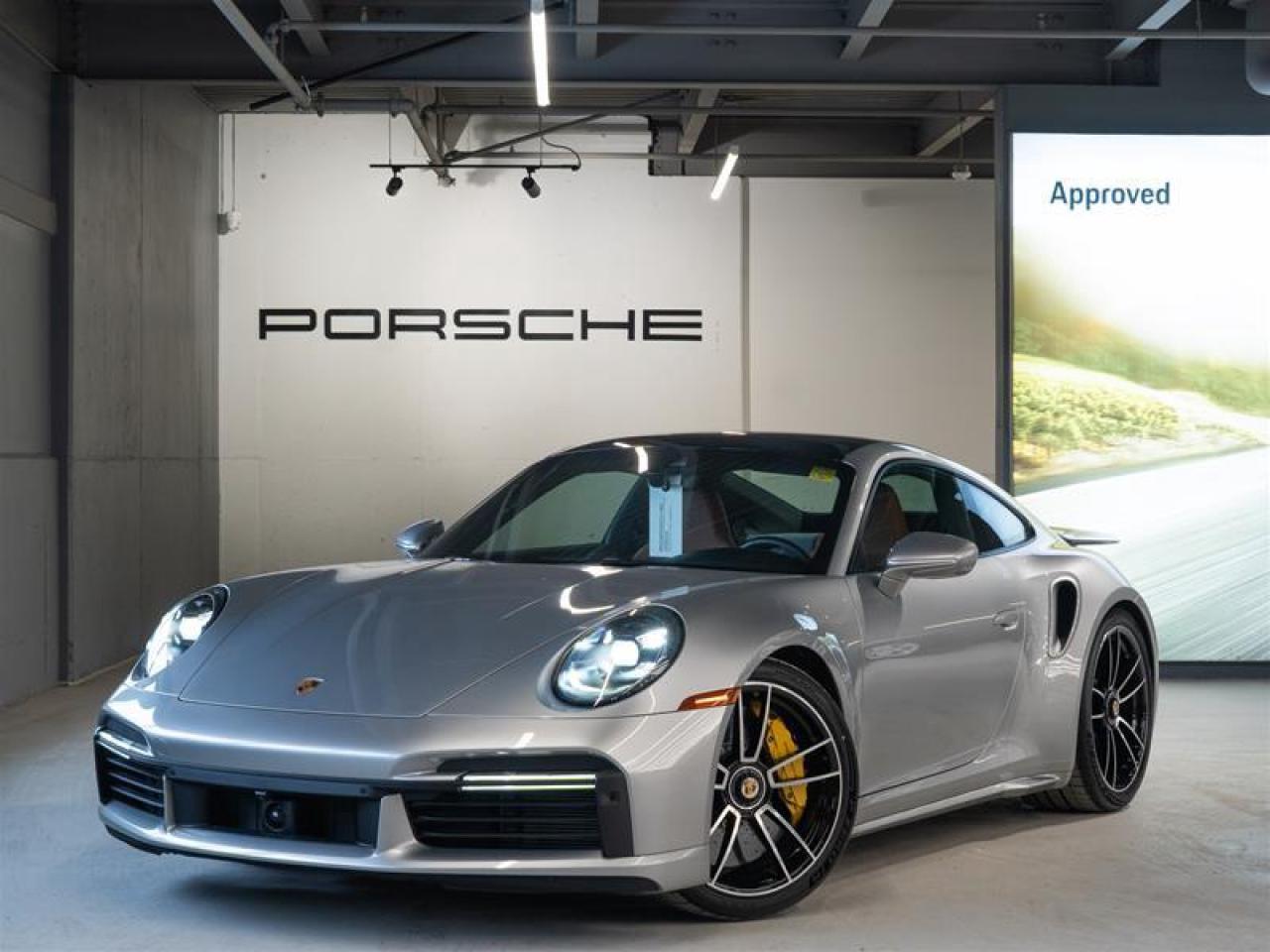 ***Leasing Options Available on Certified Pre-Owned Porsches***  The Porsche that you’ve always wanted. This 2024 911 Turbo S (MY24) has a Clean CarFax Report. With Heritage Design Interior - Classic in Black/Semi-Aniline Classic Cognac, GT-Silver Metallic, Heritage Design Package - Classic ($9,100), Electric Slide/Tilt Sunroof in Glass ($2,280), Side Skirts in Exterior Color ($860), Preparation for Roof Transport System ($70), Exterior Mirror Base in Exterior Color ($750), Rear Side Air Intakes in Exterior Color ($690), Under Door Puddle Light Projectors ($190), Exclusive Design Fuel Cap, Rear Lid Grille Vertical Slat Inlays in Exterior Color ($820), Model Designation on Rear in Exterior Color ($300), PASM Sport Suspension (Lowered 10mm) ($1,720), Front Axle Lift System ($3,150), Sport Exhaust System incl. Tailpipes in Silver ($3,990), Power Steering Plus ($310), Deletion of Quilting, Extended Heritage Design Leather Package ($4,400), Extended Dashboard and Door Panel Package in Leather ($1,760), Storage Package, Heritage Design Floor Mats, Burmester® High-End Surround Sound System ($4,540), Preparation for Deletion of Model Designation, Passenger Cupholder Trim in Leather i.c.w. Exclusive Manufaktur Leather Interiors, LED-Matrix Design Headlights in Black incl. Porsche Dynamic Light System Plus (PDLS+) ($850), Exclusive Design Taillights ($1,130), Lane Change Assist (LCA) ($1,200), Surround View ($1,640), Ambient Lighting ($660), and Porsche InnoDrive incl. Adaptive Cruise Control (ACC) and Active Lane Keep (ALK) ($3,450), this is the car for you! Look for the Porsche Approved seal when buying a pre-owned Porsche. Porsche Approved Pre-Owned Cars are inspected in compliance with our 111-point checklist and any work required is performed using only 100% Porsche Genuine Parts. As proof of the trust that we have in the quality of our vehicles, every certified pre-owned car comes with a minimum of 24 months Porsche Approved Warranty and Porsche Roadside Assistance. The Porsche Approved Warranty covers all components of your Porsche and offers the same level of security as our new car warranty. Luxury Tax is not charged on Certified Pre-Owned vehicles. Call us at 613-749-4275 and ask to speak to one of our Porsche Brand Executives. Serving the Ottawa & Gatineau region. *** Options de location disponibles pour les Porsche doccasion certifiées ***  La Porsche de vos rêves. Cette voiture 2024 911 Turbo S (MY24) a un bon rapport d’historique de véhicule de CarFax. Grâce à Heritage Design Interior - Classic in Black/Semi-Aniline Classic Cognac, GT-Silver Metallic, Heritage Design Package - Classic ($9,100), Electric Slide/Tilt Sunroof in Glass ($2,280), Side Skirts in Exterior Color ($860), Preparation for Roof Transport System ($70), Exterior Mirror Base in Exterior Color ($750), Rear Side Air Intakes in Exterior Color ($690), Under Door Puddle Light Projectors ($190), Exclusive Design Fuel Cap, Rear Lid Grille Vertical Slat Inlays in Exterior Color ($820), Model Designation on Rear in Exterior Color ($300), PASM Sport Suspension (Lowered 10mm) ($1,720), Front Axle Lift System ($3,150), Sport Exhaust System incl. Tailpipes in Silver ($3,990), Power Steering Plus ($310), Deletion of Quilting, Extended Heritage Design Leather Package ($4,400), Extended Dashboard and Door Panel Package in Leather ($1,760), Storage Package, Heritage Design Floor Mats, Burmester® High-End Surround Sound System ($4,540), Preparation for Deletion of Model Designation, Passenger Cupholder Trim in Leather i.c.w. Exclusive Manufaktur Leather Interiors, LED-Matrix Design Headlights in Black incl. Porsche Dynamic Light System Plus (PDLS+) ($850), Exclusive Design Taillights ($1,130), Lane Change Assist (LCA) ($1,200), Surround View ($1,640), Ambient Lighting ($660), and Porsche InnoDrive incl. Adaptive Cruise Control (ACC) and Active Lane Keep (ALK) ($3,450), cette voiture est parfaite pour vous! Trouvez le sceau d’approbation de Porsche lorsque vous achetez une Porsche d’occasion. Les voitures d’occasion approuvées par Porsche sont inspectées conformément à notre liste de vérification de 111 points. Tout travail requis est effectué en utilisant uniquement des pièces d’origine Porsche. Comme preuve de la confiance que nous avons dans la qualité de nos véhicules, chaque voiture d’occasion certifiée fait l’objet d’une garantie d’au moins 24 mois approuvée par Porsche et de l’assistance routière Porsche. La garantie approuvée par Porsche couvre tous les composants de votre Porsche et offre le même niveau de sécurité que notre garantie pour les véhicules neufs. La taxe de luxe n’est pas appliquée aux véhicules d’occasion certifiés. Appelez-nous au 613-749-4275 pour parler à l’un de nos directeurs de marque Porsche. Au service de la région d’Ottawa et du Gatineau.