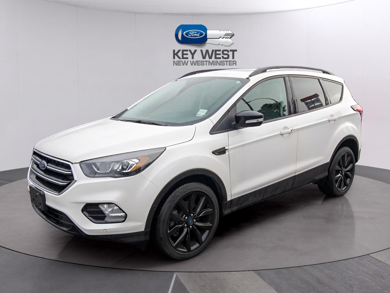 <p>Looking for a versatile and feature-packed SUV thats ready for Canadian adventures? Check out this used 2019 Ford Escape Titanium 4WD, available now at Carpages.ca! This Escape is a perfect blend of practicality and comfort, ideal for families, commuters, and anyone who loves to explore. With 127,350 KM on the odometer, this vehicle has plenty of life left and is ready to hit the road with you. The Titanium trim offers a premium experience, ensuring every drive is enjoyable.</p><p>&nbsp;</p><p>This Escape is loaded with features designed to make your life easier and more connected. From its advanced safety features to its comfortable interior, this SUV is built to impress. The 4-wheel drive system provides confidence in various weather conditions, making it a great choice for all seasons. Dont miss out on the opportunity to own a well-equipped and reliable SUV.</p><p>&nbsp;</p><p>Here are five standout features that make this 2019 Ford Escape Titanium 4WD a must-see:</p><p><br><br></p><ul><li><strong>Voice-Activated Touchscreen Navigation:</strong> Get where you need to go with ease, thanks to the intuitive navigation system.</li></ul><p>&nbsp;</p><ul><li><strong>Heated Leather Steering Wheel:</strong> Enjoy ultimate comfort, especially during those chilly Canadian mornings.</li></ul><p>&nbsp;</p><ul><li><strong>FordPass Connect 4G LTE WiFi Mobile Hotspot:</strong> Stay connected on the go with built-in Wi-Fi.</li></ul><p>&nbsp;</p><ul><li><strong>Active Park Assist:</strong> Make parking a breeze with this smart feature.</li></ul><p>&nbsp;</p><ul><li><strong>2.0L EcoBoost Engine:</strong> Experience a powerful and efficient drive with auto-start-stop technology.</li></ul><p><br><br></p><p><strong><em>Powered by AutoIntelligence&trade;</em></strong><br>Vehicle information has been generated using artificial intelligence and is provided for informational purposes only. While efforts are made to ensure accuracy, please confirm all details directly with the dealer.</p><p>&nbsp;</p><p>Experience peace of mind with our Buy With Confidence program! This vehicle comes with a comprehensive mechanical and safety inspection, Carfax report, and full disclosure. We are committed to transparent pricing. The advertised price excludes fees: $699 Documentation, $349 Registration/Insurance Transfer, $695 Finance Administration Fee (if applicable), and taxes. As BCs #1 Volume Dealer and #1 for Customer Experience on DealerRater, we prioritize your satisfaction. See Key West Ford for complete details. Book your test drive today!&nbsp; Dealer #7485</p>