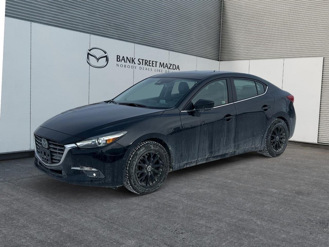 Experience the exceptional handling of the 2018 Mazda Mazda3 GT Sedan in a stylish package. With its Front-Wheel Drive and Automatic Transmission, this vehicle promises a smooth and enjoyable driving experience, perfect for navigating city streets and open highways alike. The Mazda3 GT stands out with its eye-catching alloy wheels and the added perk of a sunroof/moonroof, bringing a touch of elegance to your everyday drives. Inside, comfort takes center stage with heated seats and smart device integration, ensuring every journey is both cozy and connected. The spacious interior melds convenience and luxury effortlessly, making it a joy for both driver and passengers. Equipped with the latest technology, this Mazda3 features a backup camera and Bluetooth connection for seamless connectivity and safety on the road. It also includes advanced safety features like lane assist and brake assist, providing added peace of mind during your travels. The keyless entry and power windows add further convenience to your driving experience. The 2018 Mazda Mazda3 GT Sedan is ideal for those who appreciate a refined yet practical driving experience. Whether you are a daily commuter or a weekend adventurer, this car has all the features you need to enhance your lifestyle. Contact the dealership today to learn more and schedule your test drive. Dont miss the opportunity to own this exceptional sedan!