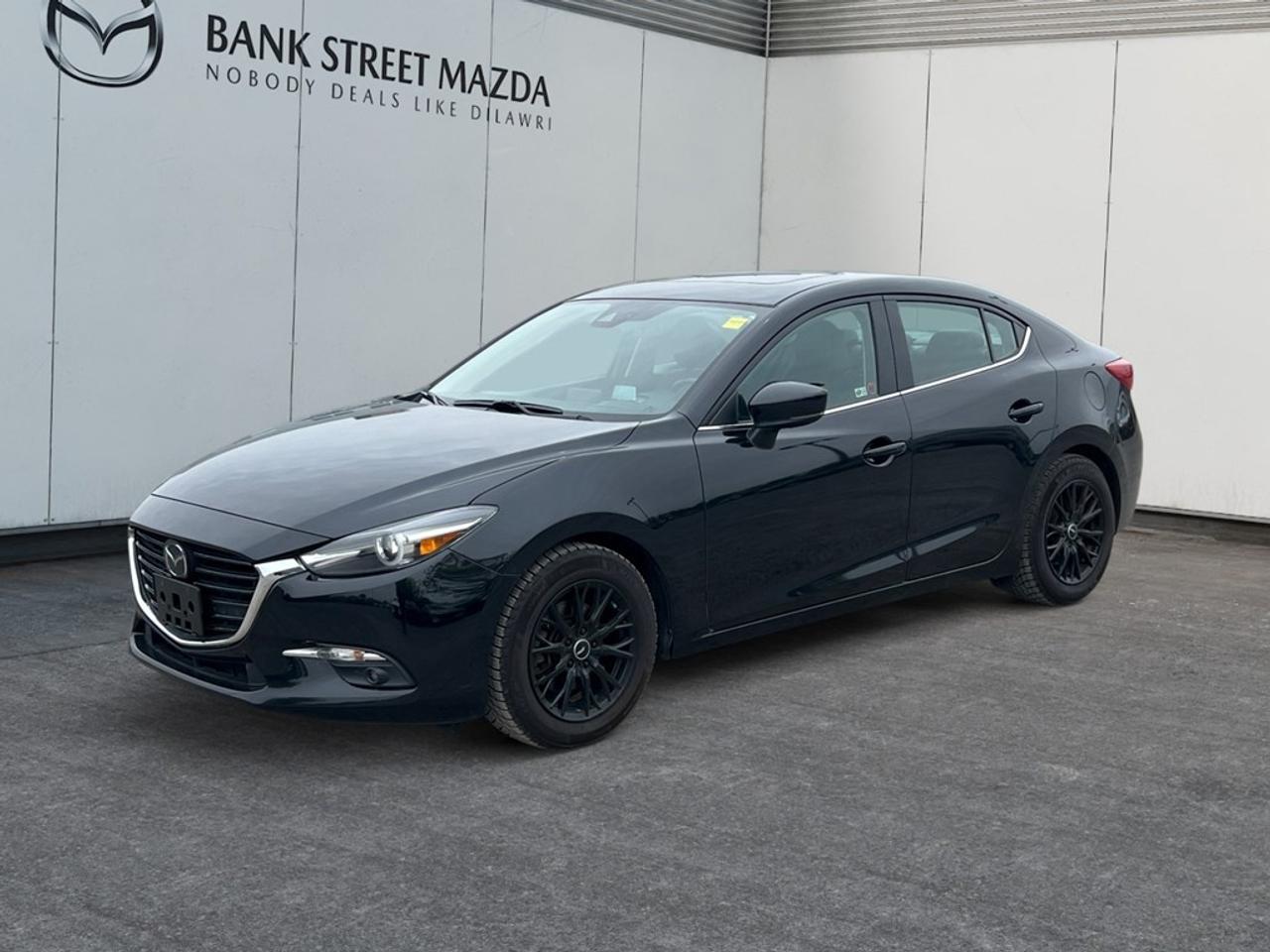 Experience the exceptional handling of the 2018 Mazda Mazda3 GT Sedan in a stylish package. With its Front-Wheel Drive and Automatic Transmission, this vehicle promises a smooth and enjoyable driving experience, perfect for navigating city streets and open highways alike. The Mazda3 GT stands out with its eye-catching alloy wheels and the added perk of a sunroof/moonroof, bringing a touch of elegance to your everyday drives. Inside, comfort takes center stage with heated seats and smart device integration, ensuring every journey is both cozy and connected. The spacious interior melds convenience and luxury effortlessly, making it a joy for both driver and passengers. Equipped with the latest technology, this Mazda3 features a backup camera and Bluetooth connection for seamless connectivity and safety on the road. It also includes advanced safety features like lane assist and brake assist, providing added peace of mind during your travels. The keyless entry and power windows add further convenience to your driving experience. The 2018 Mazda Mazda3 GT Sedan is ideal for those who appreciate a refined yet practical driving experience. Whether you are a daily commuter or a weekend adventurer, this car has all the features you need to enhance your lifestyle. Contact the dealership today to learn more and schedule your test drive. Dont miss the opportunity to own this exceptional sedan!