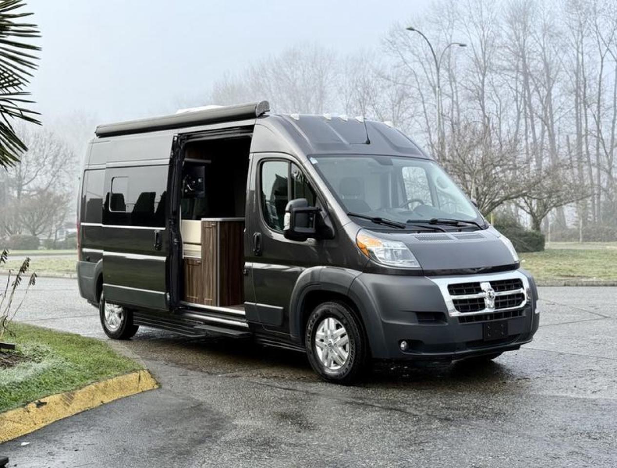 This 2018 RAM ProMaster 2500 High Roof Long Wheelbase has been converted into a well-equipped camper van, offering a practical blend of drivability and livable comfort. Powered by a 3.6L V6 engine with an automatic transmission and front-wheel drive, it features a thoughtfully designed interior that includes a kitchenette with sink, stovetop, microwave, and fridge/freezer, along with storage cabinets, a dedicated toilet area, table top, and power outlets throughout. Comfort features include Dometic air conditioning and heat, a TV, sliding window covers, and an exterior awning for added outdoor living space. The van is also equipped with cruise control, navigation, reverse camera, tow/haul mode, and full power accessories. Finished in grey with a black cloth interior, this camper measures approximately 19 ft 6 in long, 6 ft 8 in wide, and 9 ft 5 in high, making it a versatile option for road trips, extended travel, or off-grid adventures. This item is currently OFFSITE. You must register an appointment with our office to schedule an offsite viewing. Appointments must be made a minimum of one business day in advance (and as defined by the days that Repo.com is open for business) before your appointment can be scheduled and confirmed. We may, at our own discretion, instead opt to transport smaller items to Repo.coms main yard for viewing purposes.  $79,890.00 plus $375 processing fee, $80,265.00 total payment obligation before taxes.  Listing report, warranty, contract commitment cancellation fee, financing available on approved credit (some limitations and exceptions may apply). All above specifications and information is considered to be accurate but is not guaranteed and no opinion or advice is given as to whether this item should be purchased. We do not allow test drives due to theft, fraud, acts of vandalism and undetectable impaired driving. Instead we provide the following benefits: Complimentary Warranty (with options to extend), Limited Money Back Satisfaction Guarantee on Fully Completed Contracts, Contract Commitment Cancellation, and an Open-Ended Sell-Back Option. Ask seller for details or call 604-522-REPO(7376) to confirm listing availability.