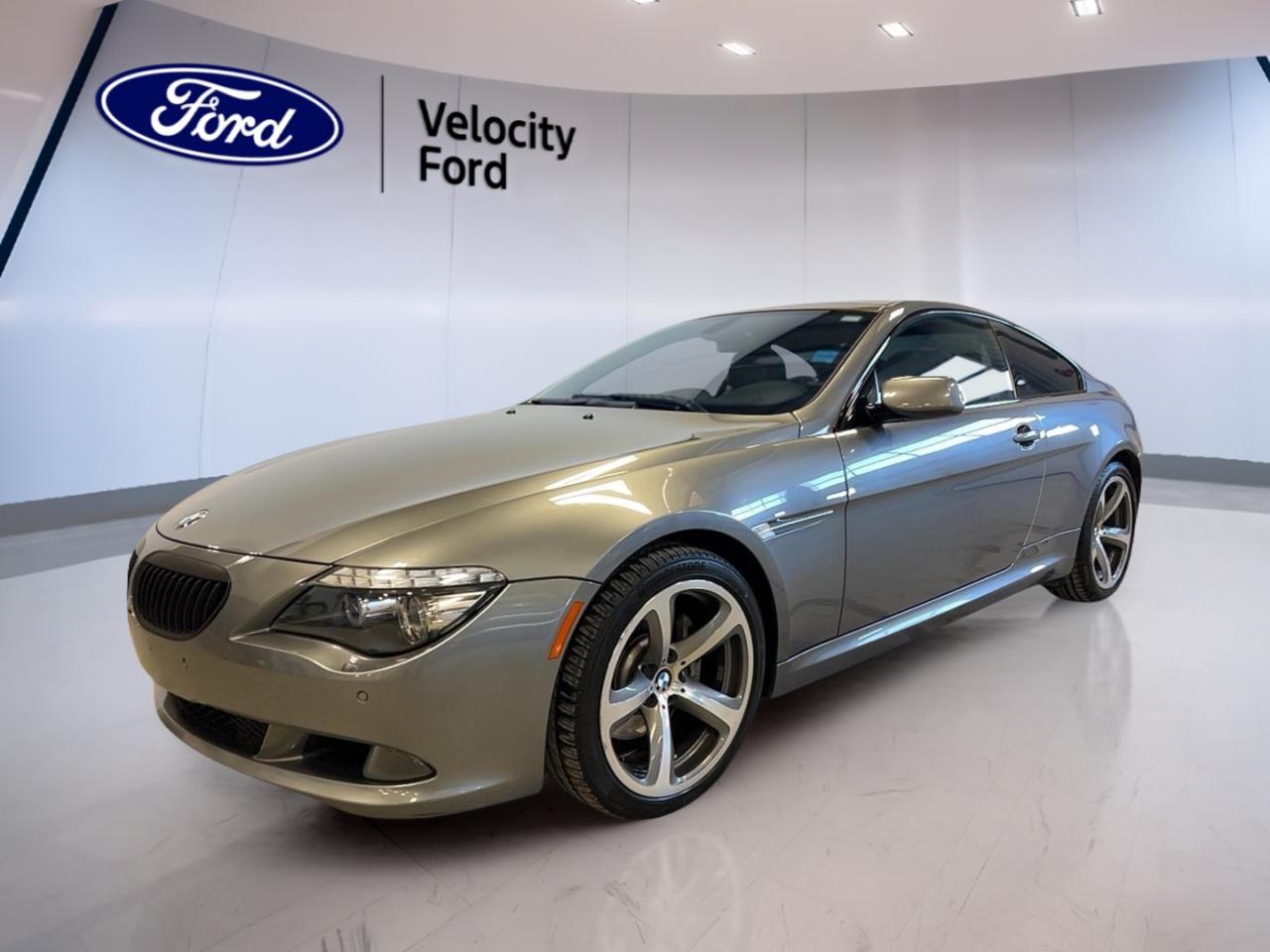 Available now at Velocity Ford in Moose Jaw, this used 2008 BMW 6 Series Coupe 650i delivers a true grand touring feel in a sleek Grey exterior with a Black interior and a 2-door coupe profile. With 104,947 km, its a well-kept option for drivers who want comfort, power, and classic BMW style.

Under the hood, this 2008 BMW 6 Series Coupe 650i is powered by a 4.8 L gas engine paired with an automatic transmission for smooth, confident driving. From daily commutes to weekend highway runs, it offers a refined balance of strong acceleration and relaxed cruising, with features chosen to keep every trip easy.

FEATURES OF THE 6 Series 6 Series Coupe 650i  
»» 4.8 L V8 grand touring power  
»» Coupe body with classic BMW stance  
»» Automatic transmission for smooth shifting  
»» Driver-focused cockpit with premium controls  

ADVANCED SAFETY FEATURES  
»» Anti-Lock Braking System for control  
»» Stability Control helps maintain traction  
»» Driver Airbag for front protection  
»» Side Impact Airbags add side protection  

PERFORMANCE AND EFFICIENCY  
»» 4.8 L gas engine performance  
»» Automatic transmission for easy driving  
»» Adjustable Suspension for tailored ride  
»» Performance Tires for sharper road feel  

COMFORT AND CONVENIENCE  
»» Dual-Zone Climate Control for balanced comfort  
»» Heated Front Seats for cold days  
»» Power Windows for quick adjustments  
»» Cruise Control for relaxed highway trips  

TECHNONOLGY AND CONNECTIVITY  
»» Navigation System helps guide every route  
»» Bluetooth Integration for hands-free calling  
»» HD Radio for clearer sound  
»» Push Button Start for quick departures  

CARGO SPACE  
»» Coupe trunk fits weekend travel bags  
»» Wide opening for easier loading  
»» Practical space for daily essentials  
»» Secure enclosed storage behind rear seats  

WHAT OTHER OWNERS LIKE  
»» Strong V8 pull at highway speeds  
»» Comfortable ride with adjustable suspension  
»» Useful navigation for road trips  
»» Heated seats and dual-zone climate  

This 2008 BMW 6 Series 6 Series Coupe 650i also includes smart visibility and convenience touches that make a difference day to day. You get HID Headlights with Automatic Headlights, plus Fog Lights for changing weather. Heated Mirrors, Electric Mirrors, and Retractable Mirrors help with winter mornings and tight parking spots.

The cabin is set up for long drives with supportive seating and memory settings. This 2008 BMW 6 Series Coupe 650i includes Memory Seats, Drivers Seat Lumbar Support, and Lumbar Support Passenger Seat, along with a Drivers Side Power Seat and Electric Passenger Seat. An Adjustable Steering Wheel and Leather Steering Wheel complete the driver-focused layout.

This 2008 BMW 6 Series 6 Series Coupe 650is VIN is: WBAEA53588CV91256.
