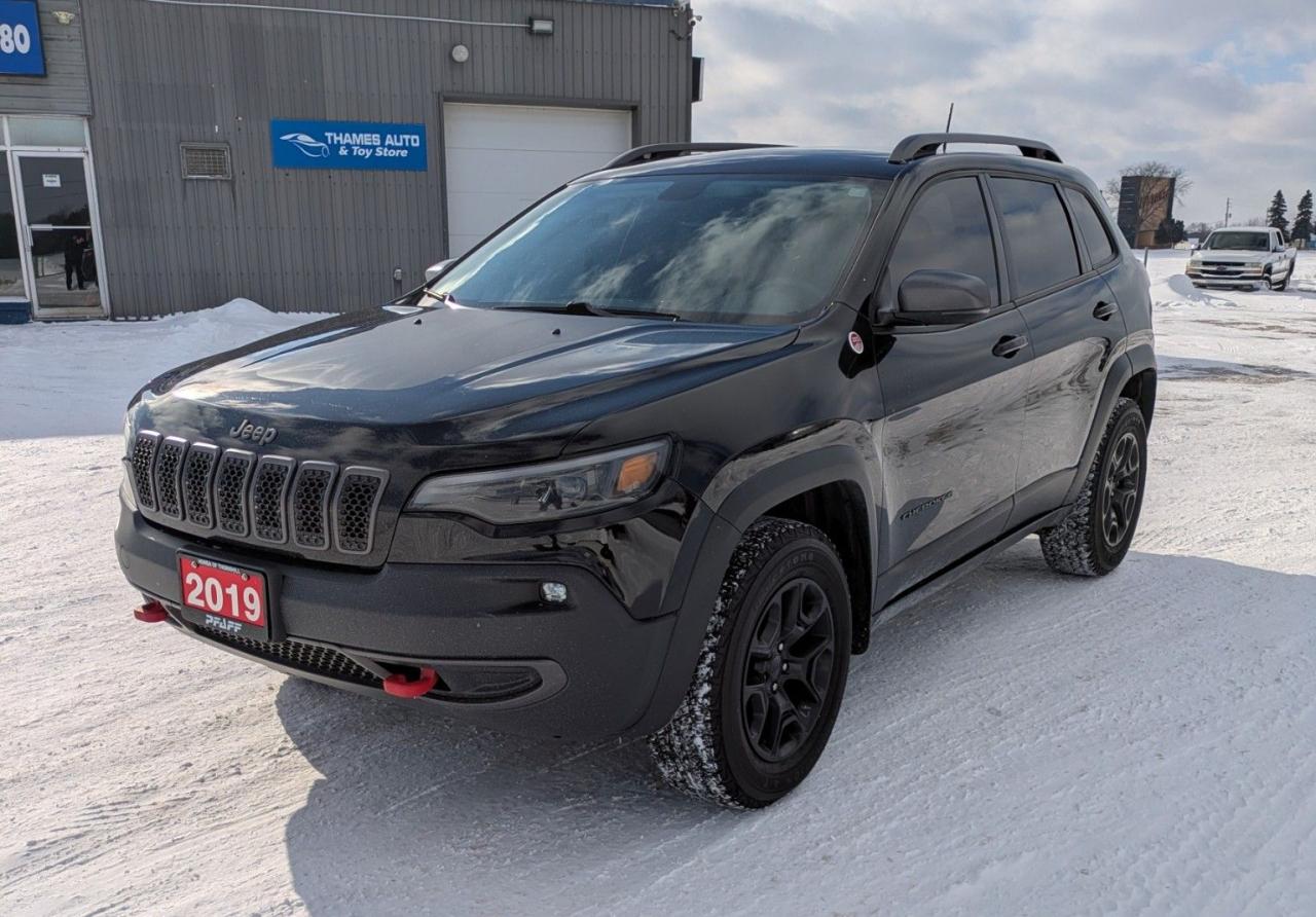 <p class=MsoNormal>&nbsp;</p><p class=MsoNormal><span style=font-size: 12.0pt; line-height: 107%; font-family: Aptos,sans-serif;>2019 Jeep Cherokee Trailhawk 4X4 - in like-new condition. Black on black on black!</span></p><p class=MsoNormal><span style=font-size: 12.0pt; line-height: 107%; font-family: Aptos,sans-serif;>With only 143,200 km on the odometer, this Trailhawk has been gently broken in and is primed for years of reliable adventures. Fully serviced, its the perfect blend of Jeep toughness and everyday comfort.</span></p><p class=MsoNormal><span style=font-size: 12.0pt; line-height: 107%; font-family: Aptos,sans-serif;>Power Under the Hood, 3.2L V6 - 9-speed automatic transmission and towing up to 4,500 lbs.</span></p><p class=MsoNormal><span lang=EN style=font-size: 12.0pt; line-height: 107%; font-family: Aptos,sans-serif; mso-ansi-language: EN;>Enjoy the Selec-Terrain&reg; Traction Management System and switch between Auto, Sport, Rock, Snow, and Mud/Sand modes.</span></p><p class=MsoNormal><span style=font-size: 12.0pt; line-height: 107%; font-family: Aptos,sans-serif;>All-terrain tires. Deep tinted windows for privacy. Power everything with a, spacious 5-passenger cabin, heated leather-trimmed seats and steering-wheel, a premium 8&rdquo; Uconnect infotainment system and navigation. Standard rearview camera.</span></p><p class=MsoNormal style=line-height: 107%;><span style=font-size: 12.0pt; line-height: 107%; font-family: Aptos,sans-serif; mso-fareast-font-family: Aptos; mso-bidi-font-family: Aptos;>Clean CARFAX Report. No accidents or damage claims. Fully Serviced, Safety Inspected & Certified.</span></p><p class=MsoNormal><a name=_Hlk211499882></a><span style=font-size: 12.0pt; line-height: 107%; font-family: Aptos,sans-serif;>Asking $16,995 + HST and Registration/Licencing. Extended warranty and Financing options are available.</span></p><p class=MsoNormal><span style=mso-bookmark: _Hlk211499882;><span style=font-size: 12.0pt; line-height: 107%; font-family: Aptos,sans-serif;>Offered by Thames Auto Sales. </span></span><a href=http://www.thamesautosales.ca><span style=mso-bookmark: _Hlk211499882;><span style=font-size: 12.0pt; line-height: 107%; font-family: Aptos,sans-serif;>www.thamesautosales.ca</span></span></a><span style=mso-bookmark: _Hlk211499882;><span style=font-size: 12.0pt; line-height: 107%; font-family: Aptos,sans-serif;> Now under new ownership and management, effective June 1, 2025.</span></span></p><p class=MsoNormal>&nbsp;</p>
