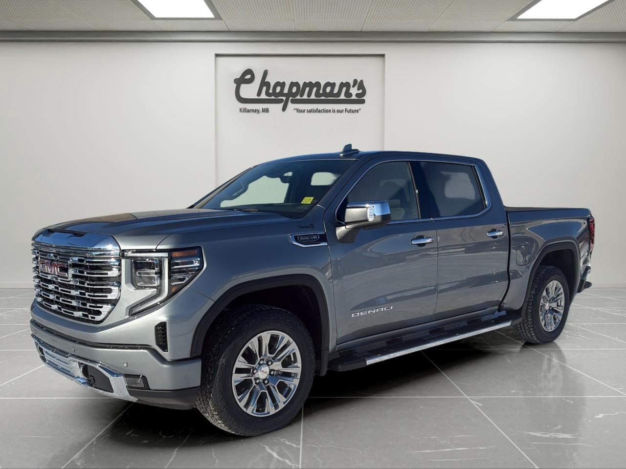 <p>The 2026 GMC Sierra 1500 Denali Crew Cab 4WD delivers premium refinement, confident V8 performance, and advanced technology in a full-size luxury pickup. Finished in <strong>Sterling Metallic</strong> with an <strong>Atmosphere/Brownstone interior</strong>, this Denali pairs upscale design with serious capability, powered by the <strong>5.3L Ecotec3 V8</strong> and equipped with the Denali Premium Suspension and Technology Package.</p><p><strong>Performance & Capability</strong></p><p>Smooth, confident performance with trailering-ready hardware and adaptive ride quality.</p><ul><li><p>5.3L Ecotec3 V8 Engine</p></li><li><p>10-Speed Automatic Transmission</p></li><li><p>4WD with 2-Speed Autotrac Transfer Case</p></li><li><p>Automatic Locking Rear Differential</p></li><li><p>Denali Premium Suspension with Adaptive Ride Control</p></li><li><p>StabiliTrak with Trailer Sway Control and Hill Start Assist</p></li><li><p>Trailering Package</p></li><li><p>Trailer Brake Controller</p></li><li><p>120V AC Power Outlets (Instrument Panel and Cargo Bed)</p></li></ul><p><strong>Interior Comfort & Convenience</strong></p><p>A refined Denali cabin designed for comfort, control, and long-distance driving.</p><ul><li><p>Heated and Ventilated Front Bucket Seats</p></li><li><p>Heated Second-Row Outboard Seats</p></li><li><p>12-Way Power Front Seats</p></li><li><p>Driver Seat and Mirror Memory</p></li><li><p>Heated Leather-Wrapped Steering Wheel</p></li><li><p>Power Tilt and Telescoping Steering Column</p></li><li><p>Adaptive Cruise Control</p></li><li><p>Wireless Charging</p></li><li><p>Bose Premium Sound System</p></li><li><p>Rear Window Defogger</p></li></ul><p><strong>Technology & Connectivity</strong></p><p>Advanced displays and seamless connectivity enhance every drive.</p><ul><li><p>GMC Premium Infotainment System</p></li><li><p>13.4" Diagonal Colour Touchscreen</p></li><li><p>Google Built-In with Navigation Capability</p></li><li><p>Wireless Apple CarPlay</p></li><li><p>Wireless Android Auto</p></li><li><p>12.3" Digital Driver Information Centre</p></li><li><p>In-Vehicle Trailering App</p></li><li><p>OnStar Basics (Up to 8 Years)</p></li><li><p>SiriusXM Audio (Trial Included)</p></li><li><p>Keyless Open and Remote Start</p></li><li><p>Head-Up Display</p></li><li><p>Rear Camera Mirror</p></li></ul><p><strong>Safety & Driver Assistance</strong></p><p>A comprehensive suite of driver-assist technologies designed to support confidence on and off the highway.</p><ul><li><p>GMC Pro Safety</p></li><li><p>Enhanced Automatic Emergency Braking</p></li><li><p>Forward Collision Alert</p></li><li><p>Front Pedestrian Braking</p></li><li><p>Lane Keep Assist with Lane Departure Warning</p></li><li><p>Following Distance Indicator</p></li><li><p>IntelliBeam Automatic High Beams</p></li><li><p>Front and Rear Park Assist</p></li><li><p>Trailer Side Blind Zone Alert</p></li><li><p>Rear Cross Traffic Braking</p></li><li><p>Rear Pedestrian Alert</p></li><li><p>Safety Alert Seat</p></li><li><p>HD Surround Vision with Bed View</p></li><li><p>Tire Pressure Monitoring with Tire Fill Alert</p></li></ul><p><strong>Exterior Highlights</strong></p><p>Signature Denali styling with functional, premium design elements.</p><ul><li><p>Chrome Assist Steps</p></li><li><p>20" Polished Aluminum Wheels</p></li><li><p>Spray-On Bedliner</p></li><li><p>GMC MultiPro Tailgate</p></li><li><p>LED Cargo Area Lighting</p></li><li><p>Power Folding Heated Mirrors with Driver-Side Auto-Dimming</p></li><li><p>LED Headlamps, Tail Lamps, and Fog Lamps</p></li><li><p>Rain-Sensing Wipers</p></li><li><p>Dual Exhaust</p></li><li><p>Power Sunroof</p></li></ul><p>2 Year/24,000 kilometer* Complimentary Oil Changes (2 total)</p><p>3 Year/60,000 kilometer* Base Warranty Coverage</p><p>5 Year/100,000 kilometer* Powertrain Component Warranty Coverage</p><p>5 Year/100,000 kilometer* Courtesy Transportation and 24/7 Roadside Assistance</p><p>6 Year/160,000 kilometer* Sheet Metal (Rust Through) Perforation Warranty Coverage</p><p>*Whichever Comes First.</p><p>Price Includes HD Flaps & 6 Tube Steps.</p><p>Price Includes Dealer Fee.</p><p>Price Excludes PST & GST.</p><p>Financing Options Available, Call For More Details.</p> <p><strong>*While every reasonable effort is made to ensure the accuracy of this information, we are not responsible for any error or omissions contained on these pages. Please verify any information in question with Chapman Motors Ltd.</strong></p>